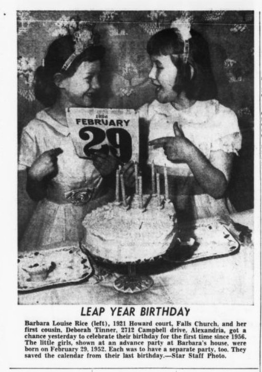 Newspaper clipping of two young girls looking at each other and holding up a page from a calendar with visible text February 29.