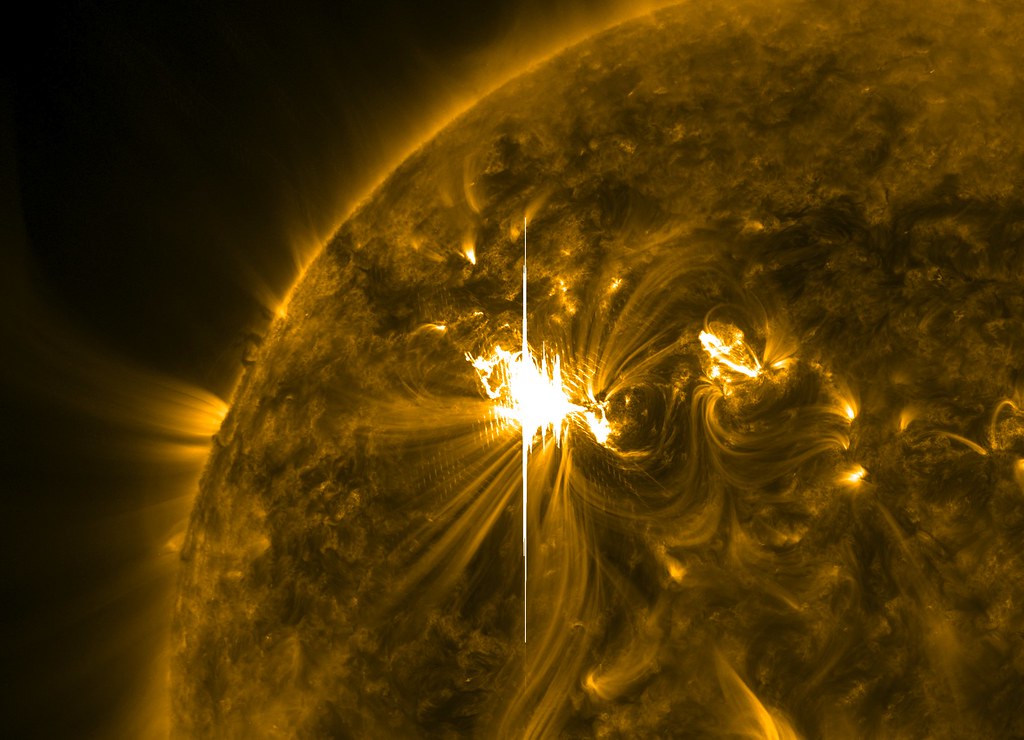 Solar X Flare as Famous Active Region Returns