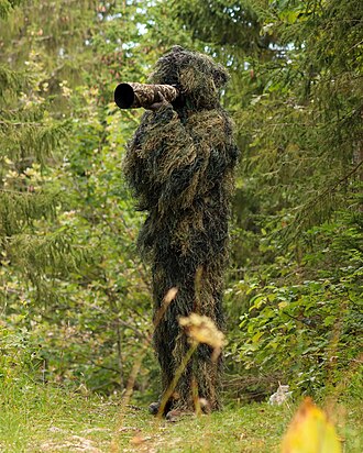 Picture of the day





Wildlife photographer in a ghillie suit. Some wild animals are very difficult to approach without disturbing them, which sometimes leads some wildlife photographers to wear a ghillie suit when they go in search of them. By remaining undetected, wildlife photographers can observe animal behaviour that would otherwise not be observable if the animal would have had knowledge of human presence.)
 #ImageOfTheDay