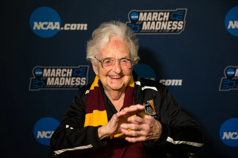 Sister Jean Dolores, beloved nun and Loyola University basketball chaplain, dies at 106 – #Catholic – 
 
 Sister Jean Dolores Schmidt at the first round game of the NCAA Tournament in Dallas on Thursday, March 15, 2018. / Credit: Lukas Keapproth/Loyola University Chicago

CNA Staff, Oct 10, 2025 / 17:07 pm (CNA).
Sister Jean Dolores Schmidt, the beloved Catholic nun who became known across the country at the age of 98 as the chaplain of the Loyola University Chicago men’s basketball team, died Oct. 9 at the age of 106. “In many roles at Loyola over the course of more than 60 years, Sister Jean was an invaluable source of wisdom and grace for generations of students, faculty, and staff,” said Mark C. Reed, Loyola president, in a statement. “While we feel grief and a sense of loss, there is great joy in her legacy. Her presence was a profound blessing for our entire community and her spirit abides in thousands of lives. In her honor, we can aspire to share with others the love and compassion Sister Jean shared with us,” he added.Sister Jean, as she was more commonly known, was born Dolores Bertha Schmidt on Aug. 21, 1919, to Joseph and Bertha Schmidt. She was raised in a devout Catholic home in San Francisco’s Castro District.Since the age of 8, Sister Jean had a calling to religious life. In her memoir, published in 2023, she recalled meeting a kind and joyful teacher who belonged to the Sisters of Charity of the Blessed Virgin Mary (BVM). Admiring this teacher, she would pray every day: “Dear God, help me understand what I should do, but please tell me I should become a BVM sister.”In 1937, she joined the Sisters of Charity of the Blessed Virgin Mary and took the name Sister Jean Dolores. In 1991, she joined the staff at Loyola Chicago and three years later became part of the basketball team, first as an academic adviser before transitioning to chaplain. Sister Jean burst onto the scene when her beloved Ramblers upset the University of Miami in the first round of the 2018 March Madness tournament with a down-to-the-wire three-point basket.Following this win, Twitter (now X) featured Sister Jean in a Twitter moment, and she received shoutouts from high-profile accounts including ESPN and former President Barack Obama. The New York Times also ran a profile on her.Sister Jean lead the team in prayer before each game — praying for her players to be safe, for the referees to be fair, and for God’s assistance during the game. She also admitted to praying for the opposing team, but “not as hard.”In her memoir, she recalled her pregame prayers with the players where she would also get on the microphone at Gentile Arena and offer a prayer for all in attendance.“Does God really care who wins a basketball game? Maybe he cares more than we think?” she wrote in her memoir.“If nothing else, I imagine God must laugh sometimes when someone prays to win a game. God sees a lot of horrible stuff going on. Sometimes he needs a good laugh. I’d like to think I give him a chuckle every time I say into that microphone, ‘Amen and go Ramblers!’”When she turned 100, Loyola Chicago announced a scholarship fund in her honor to support students, and Illinois Gov. JB Pritzker proclaimed Aug. 21, 2019, “Sister Jean Day” across the state. At 103, the Chicago train station plaza at the Loyola campus was renamed in her honor, with a large sign that read “Home of the World Famous Sister Jean!”She is survived by her sister-in-law, Jeanne Tidwell, and her niece, Jan Schmidt. Visitation and funeral arrangements will be announced soon by Loyola University.
