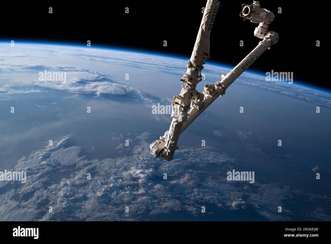A Robotic Helping Hand - The 57.7-foot-long Canadarm2 robotic arm extends from a data grapple fixture on the International Space Station’s Harmony module in this July 23, 2025, image.