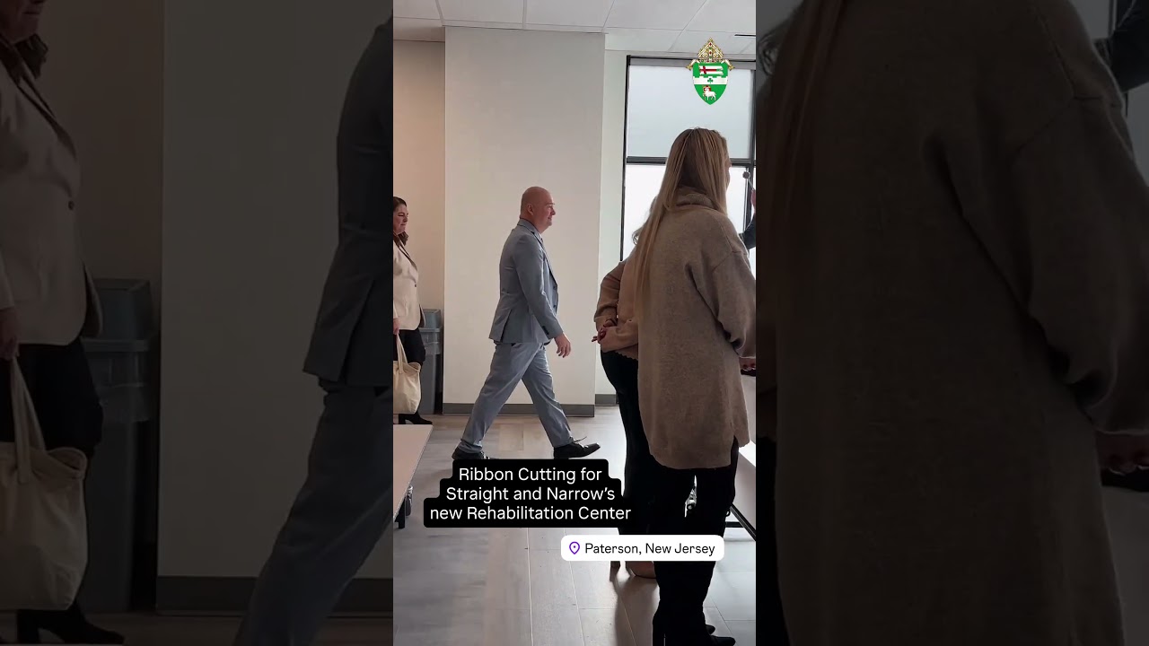 A dream realized: 6 years after the fire, Straight and Narrow dedicates new state-of-the-art building #Catholic - Blessing and ribbon-cutting of drug and alcohol rehab honors longtime leader of Catholic Charities, Diocese of Paterson
“We will rebuild.” That’s what Msgr. Herbert Tillyer said to Scott Milliken, CEO of Catholic Charities for the Diocese of Paterson, on Aug. 19, 2019, after a six-alarm fire had destroyed the main building of the drug and alcohol rehabilitation center, Straight and Narrow. The two had been in the Paterson Fire Department’s command center mobile trailer all day with Angela Nikolovski, executive director of Straight and Narrow. They were assured by officials that everyone had escaped safely, and thanks to the American Red Cross and St. Joseph’s Hospital, clients had been cared for and relocated. &nbsp;

Milliken shared the story on Dec. 8 as over 200 community leaders, lawmakers, volunteers, and supporters gathered for a blessing and ribbon-cutting of the new state-of-the-art facility, fittingly named the Monsignor Herbert K. Tillyer, P.A. Rehabilitation Center in honor of the former chairman of the board of Straight and Narrow and longtime leader of Catholic Charities organizations. With Msgr. Tillyer’s vision and wisdom, said Milliken, they have rebuilt the premier, best building they could for rehabilitation.&nbsp;&nbsp;
Nikolovski, executive director of the comprehensive social service nonprofit, said the grand opening is a testament to what can be achieved when people work together on a shared vision. “We have transformed our vision into a reality and reimagined what recovery and treatment can look like in our community.” This will allow Straight and Narrow to expand, she said, reaching and serving more individuals and families, providing “innovative, compassionate care in a space designed for healing.”
The $30 million project, a 50,000 square-foot facility, features a 50-bed halfway house for men, a state-of-the-art food-service dining and commercial kitchen to serve approximately 3,000 meals a day, men’s and women’s clinical and outpatient services, pastoral care, and administrative offices. The building is located next door to other Straight and Narrow buildings, not affected by the fire. Straight and Narrow also offers a Mommy and Me program, a Wellness Center featuring a CrossFit trainer, and Gymboree for clients’ children. Plans are underway to develop a halfway house for women, including women with children, and renovations are underway for the medical adult daycare center.

Click here to subscribe to our weekly newsletter.

“I have always said that working in Passaic County as a leader is a special network of people,” said Milliken. The dream was realized because of many generous, skilled individuals, said Milliken as he thanked NK Architects, Natoli Construction, the Catholic Charities Board of Trustees led by Father Martin Glynn, the Catholic Charities team, lawmakers including Congresswoman Nellie Pou and State Sen. Benjie Wimberly who helped secure New Jersey State budget funding, Paterson mayor André Sayegh, Passaic mayor Hector Lora, Ron Jampel, a volunteer, who guided them through the New Market Tax credit procedure, New Jersey Capital, AFLI-CII Housing Investment Trust and Valley Bank. The agency also received support from the Diocese of Paterson’s Diocesan Ministries Appeal, $1.6 million from the American Rescue Plan through the City of Paterson for an HIV program, and a grant from the Moglia Foundation to build a Wellness Center.
Kerry Alys Robinson, president and CEO of Catholic Charities USA, attended the event and shared how she was delighted to receive a letter from Pope Leo XIV in October at their annual convention. One line from the Holy Father’s message touched her heart: “Through your 168 Diocesan Catholic Charities agencies, you become agents of hope for the millions of people who approach the Church in the United States of America seeking compassion and care.” Robinson said, “The men and women of Catholic Charities Diocese of Paterson are the very agents of hope about whom the pope wrote. Indeed, the Monsignor Herbert Tillyer Rehabilitation Center is a beautiful living testament to the fact that hope cannot be extinguished.”&nbsp;
Msgr. Tillyer led the gathered in a prayer expressing gratitude and joy to God. “We rededicate ourselves to the saving mission of providing life-saving help to every person who will be served in this new rehabilitation center. Doing this faithfully and well under your guidance, dear Lord, will enable us to create genuine hope in the hearts and the minds of our precious clients and their families… we humbly and confidently ask you Lord for your guiding hand in every therapeutic intervention, in all the work that will take place here for many years and decades to come, even into the next century.”
The Diocese of Paterson’s Bishop Kevin J. Sweeney said the project has been an example of great teamwork and the good that can happen when community leaders work together. “We are all God’s children, and we believe as Christians that God calls us to see the presence of God in each and every person, especially our brothers and sisters who are most in need.” Pointing out that they were holding the event on the Feast of the Immaculate Conception and that the Feast of Our Lady of Guadalupe was to be celebrated on Dec. 12, the Bishop led the blessing, praying that Our Lord through the intercession of Mary, St. Joseph and all the angels and saints would bless the new facility and “all those who have made it possible, all those who will come to work here, to serve and to receive the gifts of healing and hope.”
Milliken encouraged guests touring the space to look at the quality of the craftsmanship guided by Natoli Construction and “made in America by our local unions.”
Many who worked on and supported the project were delighted to be in attendance.
“These types of projects make work amazing. You come here, and you feel the impact, and you know that you are making a difference,” said Harpreet Peleg, CEO of Building America and chief financial officer of the AFL-CIO Housing Investment Trust.
“It’s a really exciting day. To rebuild this…and see how beautiful it is and how many lives it is going to change; it’s extremely rewarding,” said Tom Kelly, president, Passaic Central Labor Council.
“For decades, Straight and Narrow has offered a lifeline to men and women struggling with substance use and addiction, said Congresswoman Nellie Pou. “It restores dignity, rebuilds families, and renews hope before despair can take root. Every day, the staff and volunteers here carry out the Gospel’s call to lift our neighbors up, offering compassion and clinical excellence in equal measure. With the opening of this new center, that mission continues, stronger and broader but imbued with the same unwavering commitment to the inherent worth of every man and woman.”
“We are here to celebrate a city of second chances, and a center that will give people a second chance … this is a building of mercy,” said Paterson Mayor André Sayegh.
BEACON PHOTOS | JOE GIGLI
 [See image gallery at beaconnj.org]