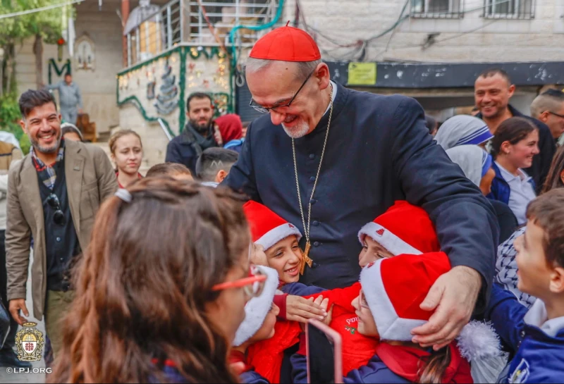 Cardinal Pizzaballa visits Holy Family Parish in Gaza days before Christmas – #Catholic – 
 
 Children greet the Latin patriarch of Jerusalem, Cardinal Pierbattista Pizzaballa, during his visit to Gaza’s Holy Family Parish on Dec. 19, 2025. / Credit: Photo courtesy of the Latin Patriarchate of Jerusalem

CNA Staff, Dec 19, 2025 / 18:35 pm (CNA).
Cardinal Pierbattista Pizzaballa, Latin patriarch of Jerusalem, arrived in Gaza City on Dec. 19 for a pastoral visit to Holy Family Parish, the only Catholic church in the Gaza Strip, just days before Christmas.Accompanied by Auxiliary Bishop William Shomali, the Latin patriarchal vicar, and a small delegation, the cardinal’s visit comes as a sign of solidarity with the small Catholic community that has endured over two years of conflict and severe hardship, including what Israel Defense Forces said was an accidental deadly attack on the parish compound last June.Upon his arrival at the parish, Pizzaballa was greeted by children, some wearing Santa hats, amid festive decorations including twinkling lights, Christmas trees, and Nativity scenes.&nbsp;The parish has sheltered hundreds of displaced people — both Christians and Muslims alike — since the war began in October 2023.The Latin Patriarchate of Jerusalem informed that as part of the patriarch’s three-day visit, he will seek to assess the parish’s current situation, including humanitarian aid efforts, ongoing relief work, and plans for the future. He is scheduled to meet with local clergy, led by parish pastor Father Gabriel Romanelli, as well as parishioners to hear directly about community needs and support initiatives.On Sunday, Dec. 21, Pizzaballa is scheduled to celebrate an early Christmas Mass at the parish, marking the start of celebrations in a community still facing many challenges, including continued restrictions on humanitarian efforts despite recent improvements under the fragile ceasefire.“Every time I come here also during the war, there is one baptism to do,” he remarked. “So there is no Christmas without baptism. It is wonderful, the best way to say that we believe in life and Jesus.”His visit “reaffirms the enduring bond of the Holy Family Parish in Gaza with the wider diocese of the Latin Patriarchate of Jerusalem, and expresses the patriarchate’s commitment to accompany its faithful in hope, solidarity, and prayer,” a statement from the patriarchate said.&nbsp;During the visit, Pizzaballa said he felt “a little bit of relief” for the first time since the war started more than two years ago and praised the Holy Family parishioners, who stayed “strong in faith during this terrible period.”During his greetings, the cardinal said he brought good wishes “from all over the world … you cannot imagine how many churches, how many groups, associations, people from all over the world — are united with you at this moment.”“We will rebuild. We will rebuild our schools … our houses … our life,” the cardinal said. “We are rooted here and we remain here. We want to be here.”