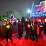 Prayers honor immigrants at Clifton’s Noche De Las Velitas #Catholic - On Dec. 7, almost 100 faithful of the Paterson Diocese prayed the Glorious Mysteries of the rosary in English and Spanish for the immigrant community facing difficult times during the diocese’s annual “Noche de las Velitas” (“Night of the Candles”), held on the grounds of Holy Face Monastery in Clifton, N.J. Bishop Kevin J. Sweeney participated in the event, a Latin-American tradition that honors the Immaculate Conception.
Adults and families with children from parishes of the diocese joined the bishop and the Benedictine monks who run Holy Face for an outdoor evening candlelight procession on monastery grounds. The faithful prayed the rosary and sang traditional songs to the Blessed Virgin Mary while a few participants recited reflections. The diocesan Office of Hispanic Ministry organized the event.
Maria Moncaleano, director of Hispanic Ministry, said, “On this second Sunday of Advent, we heard in the Gospel how John the Baptist cries out in the desert against unfairness and injustice. It may seem unusual, but part of preparing for the birth of Jesus means pointing out what is wrong and unfair in the places where we live. That is how we can begin to create the communities of kindness, love and justice that Jesus desires.”

Click here to subscribe to our weekly newsletter.

Moncaleano continued, “In these days of Advent, let us especially reach out to migrants and refugees who also are greeted with responses of ‘there is no room’ as Joseph and Mary encountered. May we demonstrate the love that we have for Jesus to create a better world where all people feel welcome.”
The Night of the Candles dates back to Dec. 7, 1854, when Pope Pius IX published his apostolic constitution “Ineffabilis Deus,” which defined the dogma of the Immaculate Conception of the Virgin Mary. People in Colombia lit candles and paper lanterns in celebration of the announcement. It is an annual tradition that Colombians and other Latin-American countries have observed ever since.
Moncaleano thanked the Benedictine monks for their hospitality and the many volunteers who helped her decorate the pathway for the procession. She especially thanked Father Yohan Serrano, chaplain for Hispanic Ministry, for his presence and support.
BEACON PHOTOS | JOE GIGLI
 [See image gallery at beaconnj.org]  