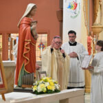 Rockaway parish continues 150-year legacy of faith, holiness #Catholic - On Nov. 22, St. Cecilia Parish in Rockaway, N.J., rejoiced in recalling its 150-year legacy of faith, service, community, and as an “incubator for vocations,” foremost among them the late Bishop Frank J. Rodimer, the sixth bishop of the Paterson Diocese in New Jersey.
During an anniversary Mass that afternoon, worshippers who filled the church also celebrated the current faith community — a population with young people and families strengthening St. Cecilia’s rich legacy of religious devotion, holiness, and spirituality. The Mass was held on the feast of the parish’s patron, St. Cecilia.
Bishop Kevin J. Sweeney was the principal celebrant and homilist of the Mass. Concelebrating the liturgy were Father Zig Peplowski, pastor of St. Cecilia’s for the past 16 years; Father Mateusz Darlak, the parish’s parochial vicar; Msgr. John Hart, pastor of Assumption Parish in Morristown, N.J., and a former pastor of St. Cecilia’s, and many priests who had been associated with the parish under Father Peplowski’s leadership.

Click here to subscribe to our weekly newsletter.

“St. Cecilia’s is a beautiful parish. Parishioners continually amaze me with their holiness,” said Father Peplowski. He said families of the parish, “an incubator for vocations,” have so far helped produce seven priests, eight religious sisters, and a religious brother. “The parish has strong Mass attendance. The people find holiness in their embrace of the sacraments, including penance, which restores their faith and commitment to Christ the Savior,” he said.
During the Nov. 22 Mass, Bishop Sweeney blessed a new wooden statue of St. Cecilia for the church, made in Italy and made possible by an anonymous donor.
The Morris County Parish also stays youthful with its school, Divine Mercy Academy (DMA). St. Cecilia School opened in 1958 and closed in 2016, when it merged with Sacred Heart of Jesus School, also in Rockway, to form DMA, which is located on the former St. Cecilia School site.
St. Cecilia’s lives out Christian service with food and coat drives and support to local organizations and diocesan Catholic Charities. The parish offers religious education for children and adults and hosts devotional activities, such as a Padre Pio Prayer Group.
St. Mary Parish in Dover, N.J., established a mission in Rockaway and built a church on Academy Street in 1869. After 1875, chaplains of St. Francis Health Resort in Denville, N.J., provided services. In 1881, St. Cecilia’s mission was advanced to parish status. In 1896, the church was moved to a new site on Church Street. A new church was built in 1955.
The Nov. 22 Mass concluded a yearlong series of 150th anniversary events, including an opening Mass last year with Bishop Emeritus Arthur J. Serratelli, a mission, and a talk about St. Cecilia’s history by Msgr. Raymond Kupke, diocesan archivist; a 40-hour Eucharistic devotion; and the parish’s first-ever carnival.
BEACON PHOTOS | JOE GIGLI
 [See image gallery at beaconnj.org]  