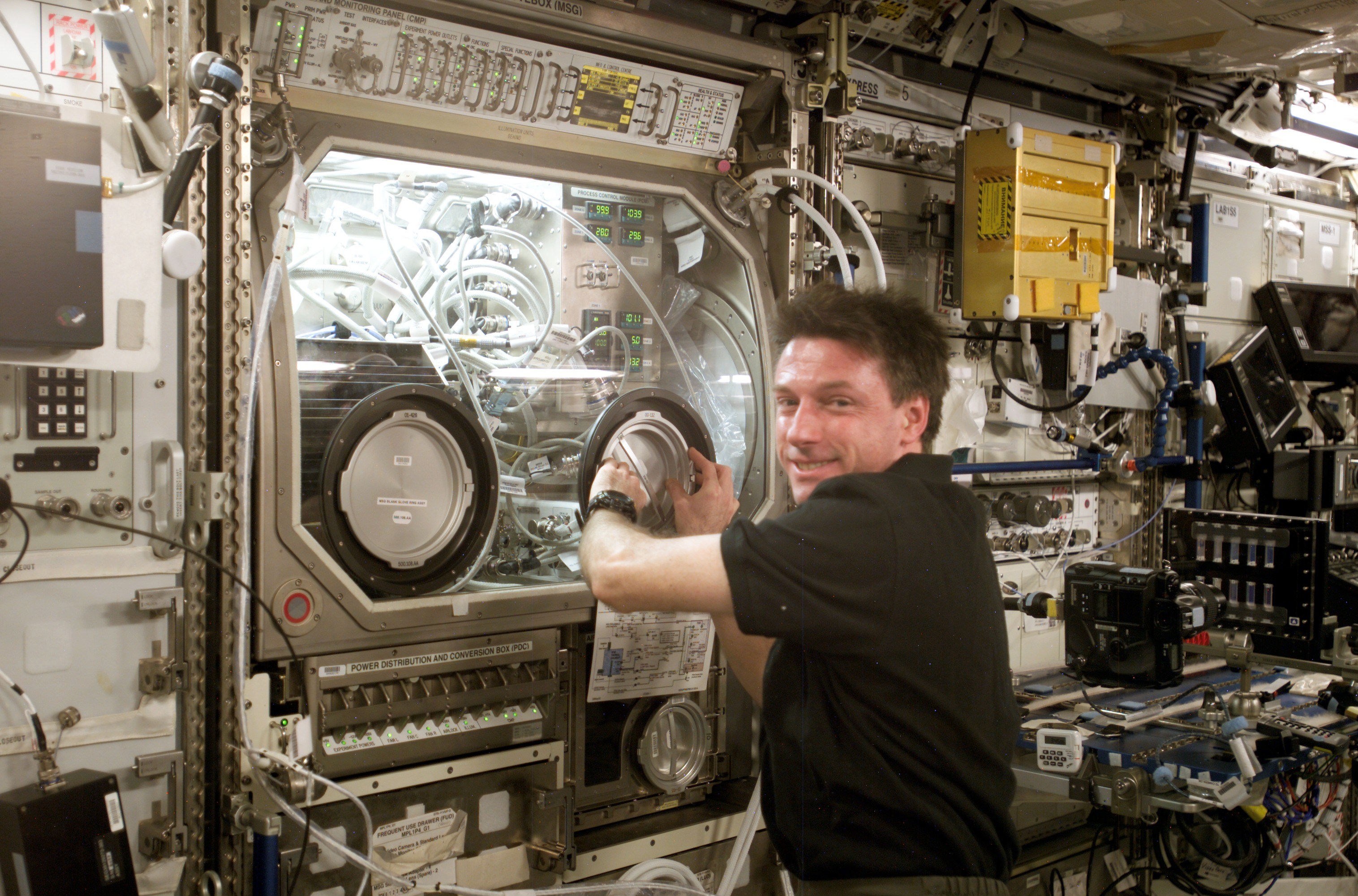 Studying Physics in Microgravity - Tiny ball bearings surround a larger central bearing during the Fluid Particles experiment, conducted inside the Microgravity Science Glovebox (MSG) aboard the International Space Station’s Destiny laboratory module.