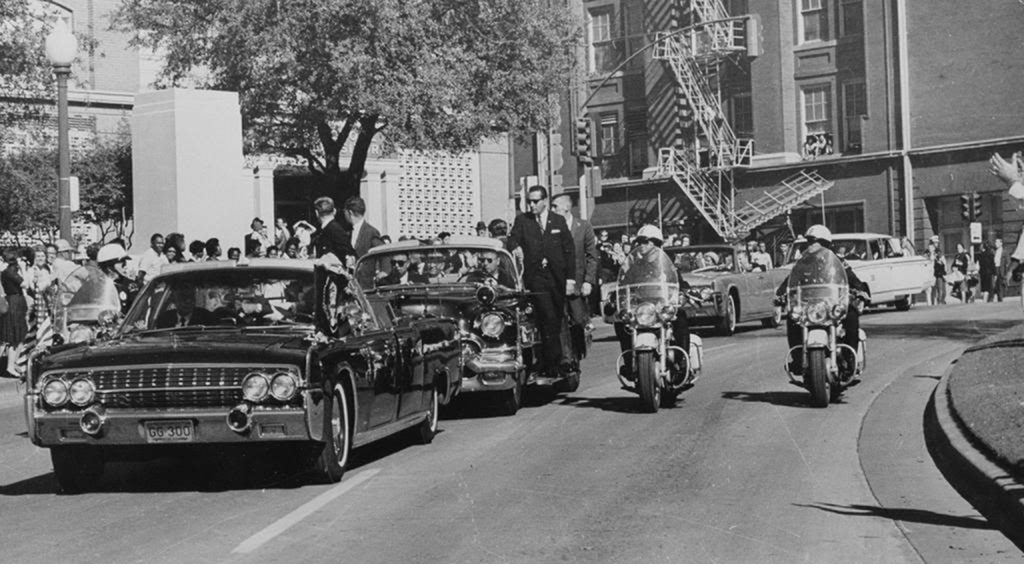 JFK motorcade enters dealy plaza seconds before oswald takes the fatal headshot