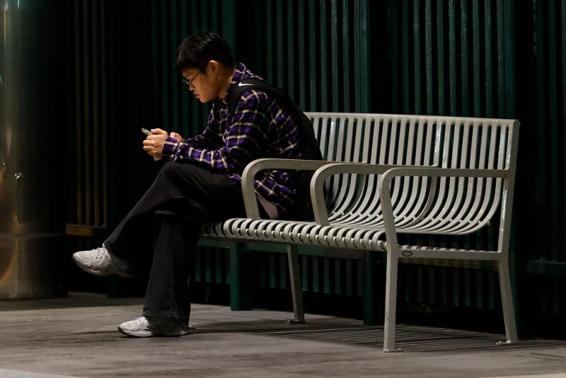 Catholic experts say new AI ‘Friend’ device undermines real relationships #Catholic
A commuter waits at the Westchester/Veterans Metro K Line station on Thursday, Oct. 2, 2025, in Los Angeles. / Credit: Carlin Stiehl/Los Angeles Times via Getty Images
Washington, D.C. Newsroom, Oct 21, 2025 / 07:00 am (CNA).
A controversial ad campaign posted in the New York City subway system has sparked criticism and vandalism over the past few weeks. The print ads are selling an AI companion necklace called “Friend” that promises to be “someone who listens, responds, and supports.”The device first launched in 2024, retailing at 9. It is designed to listen to conversations, process the information, and send responses to the user’s phone via a connected app. While users can tap the disc’s button to prompt an immediate response, the product will also send unprompted texts. The device’s microphones don’t offer an off switch, so it is constantly listening and sending messages based on conversations it picks up.CNA did not receive a response to a question from Friend.com about the success of its subway ad campaign and how many people are currently using the devices, but Sister Nancy Usselmann, FSP, director of the Daughters of St. Paul’s Pauline Media Studies who also studies AI, told CNA that “people are turning to AI for companionship because they find human relationships too complicated.” But “without that complicatedness, we cannot grow to become the best that we can be. We remain stagnant or selfish, which is a miserable existence,” she said.Creating ‘Friend’ amid loneliness epidemic Avi Schiffmann, the 22-year-old who started Friend.com, was a Harvard student before leaving school to focus on a number of projects. At 18, he created a website that tracked early COVID-19 data from Chinese health department sources. In 2022, he built another website that matched Ukrainian refugees with hosts around the world to help them find places to stay. He then founded Friend and now serves as the company’s CEO. Schiffmann and his company first turned heads when an eerie video announcing the new gadget was released in July 2024. The advertisement featured four different individuals interacting with their “friends.” One woman takes a hike with her pendant, while another watches a movie with hers. A man gets a text from his “friend” while playing video games with his human friends. He first appears to be sad and lonely around his friends, until his AI “friend” texts him, which appears to put him at ease.The marketing video ends with a young man and woman spending time together as the woman discusses how she has only ever brought “her” to where they are hanging out, referencing her AI gadget. “It’s so strange because it’s awkward to have an AI in between a human friendship,” Usselmann said about the video ad. Hundreds took to the comments section of the YouTube video to respond — mostly negatively — to both the Friend.com ads and the technology. Commentators called out the company for capitalizing on loneliness and depression. One user even called the video “the most dystopian advertisement” he had ever seen, and others wrote the video felt like a “horror film.”“While its creators might have good intentions to bring more people the joys of companionship, they are misguided in trying to achieve this through a digital simulacrum,” Father Michael Baggot, LC, professor of bioethics at the Pontifical Athenaeum Regina Apostolorum in Rome, told CNA.The device “suffers from a misnomer, since authentic friendship involves an interpersonal relationship of mutual support,” said Baggot, who studies AI chatbots and works on the development of the Catholic AI platform Magisterium AI. “The product risks both worsening the loneliness epidemic by isolating users from others and undermining genuine solitude by intruding on quiet moments with constant notifications and surveillance. Friend commodities connection and may exploit human emotional vulnerabilities for profit,” he said, adding: “It might encourage users to avoid the challenging task of building real relationships with people and encourage them to settle for the easily controllable substitute.” Usselmann agreed. “Only by reaching out in genuine compassion and care can another person who feels lonely realize that they matter to someone else,” she said. “We need to get to know our neighbors and not remain so self-centered in our apartments, neighborhoods, communities, or places of work.”AI device ad campaign causes stirIn a post to social media platform X on Sept. 25, Schiffmann announced the launch of the subway ad campaign. The post has more than 25 million views and nearly 1,000 comments criticizing the pendant and campaign — and some commending them.Dozens of the ads have since been torn up and written on. People have posted images to social media of the vandalized ads with messages about the surveillance dangers and the general threats of chatbots. One urged the company to “stop profiting off of loneliness,” while another had “AI is not your friend” written on it.One person added to the definition of “friend,” writing it is also a “living being.” It also had the message: “Don’t use AI to cure your loneliness. Reach out into the world!”Usselmann said the particular issue with the campaign and device is “the tech world assuming certain words and giving them different connotations.” “A ‘friend’ is someone with whom you have a bond based on mutual affection,” she said. “A machine does not have real affection because it cannot love. It does not have a spiritual soul from which intellect, moral agency, and love stem.”She continued: “And from a Christian understanding, a friend is someone who exhibits sacrificial love, who supports through the ups and downs of life, and who offers spiritual encouragement and forgiveness. An AI ‘friend’ can do none of those things.” Catholic experts say new AI ‘Friend’ device undermines real relationships #Catholic
A commuter waits at the Westchester/Veterans Metro K Line station on Thursday, Oct. 2, 2025, in Los Angeles. / Credit: Carlin Stiehl/Los Angeles Times via Getty Images
Washington, D.C. Newsroom, Oct 21, 2025 / 07:00 am (CNA).
A controversial ad campaign posted in the New York City subway system has sparked criticism and vandalism over the past few weeks. The print ads are selling an AI companion necklace called “Friend” that promises to be “someone who listens, responds, and supports.”The device first launched in 2024, retailing at 9. It is designed to listen to conversations, process the information, and send responses to the user’s phone via a connected app. While users can tap the disc’s button to prompt an immediate response, the product will also send unprompted texts. The device’s microphones don’t offer an off switch, so it is constantly listening and sending messages based on conversations it picks up.CNA did not receive a response to a question from Friend.com about the success of its subway ad campaign and how many people are currently using the devices, but Sister Nancy Usselmann, FSP, director of the Daughters of St. Paul’s Pauline Media Studies who also studies AI, told CNA that “people are turning to AI for companionship because they find human relationships too complicated.” But “without that complicatedness, we cannot grow to become the best that we can be. We remain stagnant or selfish, which is a miserable existence,” she said.Creating ‘Friend’ amid loneliness epidemic Avi Schiffmann, the 22-year-old who started Friend.com, was a Harvard student before leaving school to focus on a number of projects. At 18, he created a website that tracked early COVID-19 data from Chinese health department sources. In 2022, he built another website that matched Ukrainian refugees with hosts around the world to help them find places to stay. He then founded Friend and now serves as the company’s CEO. Schiffmann and his company first turned heads when an eerie video announcing the new gadget was released in July 2024. The advertisement featured four different individuals interacting with their “friends.” One woman takes a hike with her pendant, while another watches a movie with hers. A man gets a text from his “friend” while playing video games with his human friends. He first appears to be sad and lonely around his friends, until his AI “friend” texts him, which appears to put him at ease.The marketing video ends with a young man and woman spending time together as the woman discusses how she has only ever brought “her” to where they are hanging out, referencing her AI gadget. “It’s so strange because it’s awkward to have an AI in between a human friendship,” Usselmann said about the video ad. Hundreds took to the comments section of the YouTube video to respond — mostly negatively — to both the Friend.com ads and the technology. Commentators called out the company for capitalizing on loneliness and depression. One user even called the video “the most dystopian advertisement” he had ever seen, and others wrote the video felt like a “horror film.”“While its creators might have good intentions to bring more people the joys of companionship, they are misguided in trying to achieve this through a digital simulacrum,” Father Michael Baggot, LC, professor of bioethics at the Pontifical Athenaeum Regina Apostolorum in Rome, told CNA.The device “suffers from a misnomer, since authentic friendship involves an interpersonal relationship of mutual support,” said Baggot, who studies AI chatbots and works on the development of the Catholic AI platform Magisterium AI. “The product risks both worsening the loneliness epidemic by isolating users from others and undermining genuine solitude by intruding on quiet moments with constant notifications and surveillance. Friend commodities connection and may exploit human emotional vulnerabilities for profit,” he said, adding: “It might encourage users to avoid the challenging task of building real relationships with people and encourage them to settle for the easily controllable substitute.” Usselmann agreed. “Only by reaching out in genuine compassion and care can another person who feels lonely realize that they matter to someone else,” she said. “We need to get to know our neighbors and not remain so self-centered in our apartments, neighborhoods, communities, or places of work.”AI device ad campaign causes stirIn a post to social media platform X on Sept. 25, Schiffmann announced the launch of the subway ad campaign. The post has more than 25 million views and nearly 1,000 comments criticizing the pendant and campaign — and some commending them.Dozens of the ads have since been torn up and written on. People have posted images to social media of the vandalized ads with messages about the surveillance dangers and the general threats of chatbots. One urged the company to “stop profiting off of loneliness,” while another had “AI is not your friend” written on it.One person added to the definition of “friend,” writing it is also a “living being.” It also had the message: “Don’t use AI to cure your loneliness. Reach out into the world!”Usselmann said the particular issue with the campaign and device is “the tech world assuming certain words and giving them different connotations.” “A ‘friend’ is someone with whom you have a bond based on mutual affection,” she said. “A machine does not have real affection because it cannot love. It does not have a spiritual soul from which intellect, moral agency, and love stem.”She continued: “And from a Christian understanding, a friend is someone who exhibits sacrificial love, who supports through the ups and downs of life, and who offers spiritual encouragement and forgiveness. An AI ‘friend’ can do none of those things.”