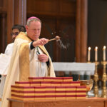 Faithful honored for distinguished service with Vivere Christus Award #Catholic - The Paterson Diocese in New Jersey recognized 64 individuals, couples, and families in appreciation for their outstanding service to the Church and the world with the Vivere Christus Award. Bishop Kevin J. Sweeney thanked the recipients for their “generosity of time, talent, and treasure” as he presided at the awards ceremony in the Cathedral of St. John the Baptist in Paterson, N.J., on Oct. 19.
Families, friends, fellow parishioners, priests, and religious filled St. John’s to watch the honorees receive this special award — a brass medal, three inches in diameter. The medal is embossed with the Latin inscription “Vivere Christus Est,” meaning “To live is Christ.” Recipients were nominated by their parishes.
“Today, we celebrate missionaries and mission with the Universal Church,” Bishop Sweeney said in his homily. He made a pastoral connection between the local Vivere Christus ceremony and a Mass the diocese held that day for World Mission Sunday. He told the award recipients, “The harvest is rich and the laborers are few. We’re so grateful for the generosity of time, talent, and treasure of so many throughout our diocese.”

Click here to subscribe to our weekly newsletter.

During the ceremony, Bishop Sweeney blessed the awards. Salesian Sister Theresa Lee, diocesan chancellor and delegate to religious, assisted the bishop with distributing the awards, while Miriam Perez called the names of each recipient and their nominating parish to come forward to receive their medals. The Diocesan Office of Worship coordinated the event.
After the ceremony, award recipients enjoyed an opportunity to take a photo with Bishop Sweeney and a reception.
Bishop Emeritus Arthur J. Serratelli created the award in 2009.
Many parishes announced their Vivere Christus recipients in their bulletins, praising them for their dedication to their faith communities and the Church. Our Lady of Mount Carmel (OLMC) Parish in the Swartwood neighborhood of Stillwater Township, called its recipient, Tom Rivara, “one of our most reliable ushers at the 7:30 a.m. Mass, a role he fulfills faithfully each week.”
“He’s also become something of a parish handyman, generously offering his time and skills to assist with maintenance and repairs around our buildings and grounds,” according to OLMC’s bulletin. “Tom’s dedication is quiet but constant. He’s always ready to lend a hand wherever needed. We are deeply grateful to Tom and to his family for their active presence and for the many ways they share their time and talents to serve our community.”
BEACON PHOTOS | JOE GIGLI
 [See image gallery at beaconnj.org]  