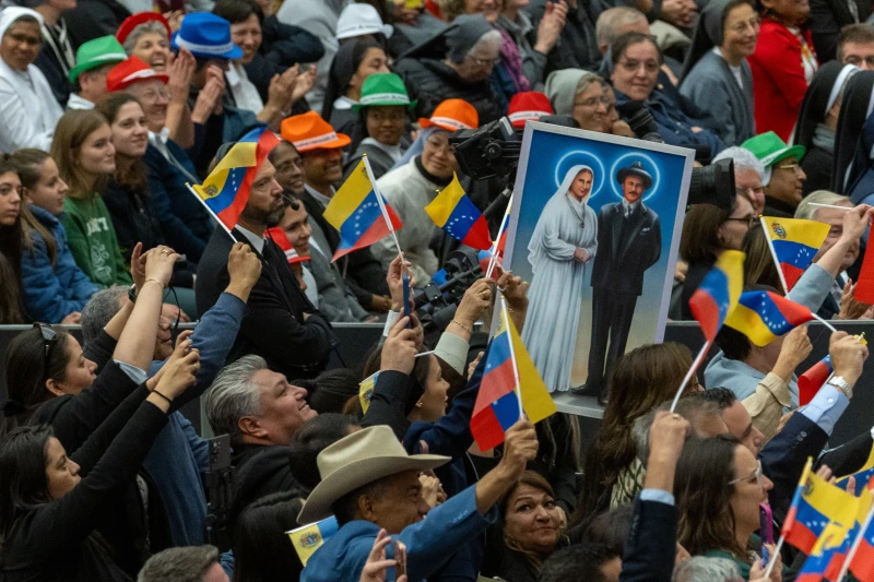 Political tensions surface amid celebrations honoring Venezuela’s 2 new saints – #Catholic – 
 
 Venezualans celebate their country’s two new saints during the canonization ceremony on Oct. 19, 2025, in St. Peter’s Square at the Vatican. / Credit: Daniel Ibáñez/EWTN News

Vatican City, Oct 20, 2025 / 14:23 pm (CNA).
Underlying political tensions have surfaced among Venezuelans in Rome celebrating the recent canonization of the country’s first two saints, José Gregorio Hernández and Mother Carmen Rendiles Martínez.A Venezuelan government delegation led by Carmen Meléndez, mayor of Caracas, and hundreds of pilgrims from the Latin American nation were among the 70,000 people who attended the Oct. 19 canonization ceremony led by Pope Leo XIV in St. Peter’s Square.However, in the days prior to Venezuelans converging at the Vatican to celebrate their country’s newly-proclaimed saints, reports of evident discord between government officials and citizens regarding President Nicolás Maduro’s authoritarian regime have also emerged.Over the weekend, activists connected to the opposition political movement Vente Venezuela, led by 2025 Nobel Peace Prize winner María Corina Machado, shared posts on Instagram highlighting their cause to free hundreds of men and women political prisoners.The activists carried posters with photos of men and women detained by Maduro’s government with the slogan “Release All Political Prisoners” at an Oct. 18 protest in Piazza Venezia, a public square near the Vatican, and at the Oct. 19 canonization ceremony held in St. Peter’s Square. The Venezuelan government’s political agenda in Rome had also been called into question by the media in the days preceding the canonizations of the country’s first saints, with critics implying their presence at the Vatican is an attempt to project a positive image of national pride and unity under the Maduro regime.Last week, a scuffle broke out between Venezuelan Vatican journalist Edgar Beltrán and  Venezuelan businessman Ricardo Cisneros, a member of the Venezuelan government delegation present at the canonization, at an event held at the Lateran University of Rome to honor the two new saints.During the Oct. 17 event, Beltrán’s interview with the Vatican’s substitute for the Secretariat of State, Archbishop Edgar Robinson Peña Parra, was interrupted by Cisneros after the prelate was asked about the Maduro government’s “apparent politicization” of the canonizations, according to Catholic news outlet The Pillar.Undemocratic measures and human rights violations in Venezuela have continued to garner increasing international attention, particularly since January when Maduro was sworn in for a third term after contested presidential election results.Meanwhile, earlier this month opposition leader Machado was awarded the Nobel Peace Prize for her tireless work in “promoting democratic rights for the people of Venezuela” and for “her struggle to achieve a just and peaceful transition from dictatorship to democracy.”   On Monday, Vatican Secretary of State Cardinal Pietro Parolin in a Mass of thanksgiving for the two saints held inside St. Peter’s Basilica urged Venezuelans to respect human rights and “create spaces for encounter and democratic coexistence.”“Only in this way, dear Venezuela, will you be able to respond to your calling for peace, if you build it on the foundations of justice, truth, freedom, and love,” the cardinal said in his Oct. 20 homily.
