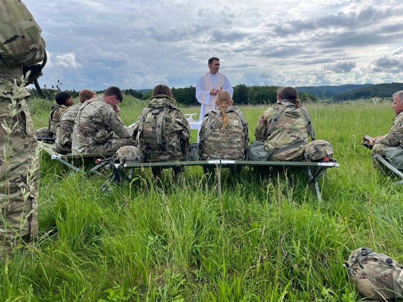 Self-care is stewardship, not selfishness, Catholic therapist tells chaplains #Catholic
Father Adam Muda, a chaplain for the U.S. Army, celebrates Mass on the field with soldiers while in Germany. / Credit: Photo courtesy of Father Adam Muda
CNA Staff, Oct 23, 2025 / 07:00 am (CNA).
During Pastoral Care Week, celebrated Oct. 19–25, a Catholic psychotherapist encouraged a group of Catholic chaplains and ministers to pursue prayer, rest, and self-care in light of burnout — a challenge that often accompanies their unique work.At an Oct. 22 webinar, “Carrying the Cross Without Burnout: Self-Care for Catholic Chaplains,” Adrienne Koller, a Catholic psychotherapist and founder of Strong Self Psychotherapy, encouraged chaplains to make time for spiritual and emotional renewal. The webinar, organized by the National Association of Catholic Chaplains (NACC), a group that educates and supports Catholic chaplains across the country, highlighted the importance of finding rest amid the emotional toll of ministry.“God doesn’t call us to self-erasure,” Koller told the nearly 100 chaplains who attended the webinar. “He calls us to stewardship of our bodies, our minds, and spirits.”Adrienne Koller, a Catholic psychotherapist and founder of Strong Self Psychotherapy, leads an Oct. 22, 2025, webinar organized by the NACC on finding renewal amid burnout. Credit: Screenshot of webinarKoller described self-care as “stewardship” and “caring for the vessel God entrusted to you.”“One of the most powerful mindset shifts I’ve seen in ministry is this: Self-care is not selfishness; it’s stewardship,” Koller said. “You are the vessel God entrusted with the work he gave you, and taking care of that vessel honors him.”“You’re not taking away from your calling. You’re strengthening it,” she said. “Renewal isn’t an indulgence — it’s obedience.” Erica Cohen Moore, executive director of NACC, highlighted the importance of caring for chaplains, both during Pastoral Care Week and throughout the year. “Our chaplains are often called into spaces where few others are willing or able to go,” Cohen Moore told CNA. “They serve people in some of the most marginalized and challenging situations, where grief and suffering can be profound.” Pastoral Care Week “gives opportunities for organizations and institutions of all types to recognize the spiritual caregivers in their midst and the ministry that the caregivers provide,” according to the NACC’s website.Chaplains are often priests, but seminarians, deacons, religious brothers and sisters, and laymen and laywomen can all serve as chaplains, providing professional spiritual and emotional support in a range of areas — often in prisons, hospitals, fire departments, and campuses. To help prepare and support chaplains, the NACC offers a variety of resources, training, community, and support for chaplains, both Catholic and non-Catholic. What does burnout look like? “Over the years, I’ve walked with countless individuals who appear incredibly strong on the outside yet wrestle with exhaustion, doubt, or the feeling that their work has taken more from them than they have time to replenish,” Koller told attendees. Koller noted that the “emotional weight” of service can lead to burnout.“That emotional weight, it doesn’t mean you’re doing something wrong; it means you’re human,” she said. “But we do take on that emotional weight, and that can lead, if unchecked, to burnout.” “Burnout doesn’t happen because we’re weak or we’re incapable,” Koller continued. “It happens because we care deeply, we give fully, and sometimes we forget to refill our own cup.”To combat the weight of service, Koller encouraged ministers to pray before and after each difficult meeting or encounter, and to offer the weight of those challenges to the Lord. She also led the group in grounding prayer exercises that incorporate breathing into prayer. Erica Cohen Moore is the executive director of the National Association of Catholic Chaplains. Credit: Photo courtesy of Erica Cohen MooreCohen Moore noted that burnout is a “very real concern” that chaplains face — one that her organization works to combat through the resources they provide. The association educates chaplains with a program called Clinical Pastoral Education (CPE), which is “a process that equips them to manage burnout and care for themselves and one another,” according to Cohen Moore.The group also offers webinars on topics such as self-care, mental illness and trauma, and mental health, as well as networking groups and in-person gatherings, and publishes a magazine called Works of Hope.The association plans to launch a learning institute early next year to include a course on “sustaining pastoral ministers and helping them avoid burnout,” Cohen Moore said. “Burnout is a very real concern in our field, and we take it seriously as we continue exploring new ways to provide care and connection,” Cohen Moore said. ‘I will give you rest’ When Koller speaks with “those in service, especially chaplains and first responders,” she said that one verse “always comes to mind.” In Matthew 11:28, Jesus says: “Come to me, all you who labor and are burdened, and I will give you rest.”Koller noted that Christ “doesn’t say: ‘Keep pushing, work harder, work harder, deplete yourself, run yourself into the ground.” “No — he says, ‘Come to me,’” she said.“That invitation isn’t to perform,” Koller continued. “It’s to rest, in a way, to surrender the illusion that we have to carry everything alone. That’s where our renewal begins.” Self-care is stewardship, not selfishness, Catholic therapist tells chaplains #Catholic
Father Adam Muda, a chaplain for the U.S. Army, celebrates Mass on the field with soldiers while in Germany. / Credit: Photo courtesy of Father Adam Muda
CNA Staff, Oct 23, 2025 / 07:00 am (CNA).
During Pastoral Care Week, celebrated Oct. 19–25, a Catholic psychotherapist encouraged a group of Catholic chaplains and ministers to pursue prayer, rest, and self-care in light of burnout — a challenge that often accompanies their unique work.At an Oct. 22 webinar, “Carrying the Cross Without Burnout: Self-Care for Catholic Chaplains,” Adrienne Koller, a Catholic psychotherapist and founder of Strong Self Psychotherapy, encouraged chaplains to make time for spiritual and emotional renewal. The webinar, organized by the National Association of Catholic Chaplains (NACC), a group that educates and supports Catholic chaplains across the country, highlighted the importance of finding rest amid the emotional toll of ministry.“God doesn’t call us to self-erasure,” Koller told the nearly 100 chaplains who attended the webinar. “He calls us to stewardship of our bodies, our minds, and spirits.”Adrienne Koller, a Catholic psychotherapist and founder of Strong Self Psychotherapy, leads an Oct. 22, 2025, webinar organized by the NACC on finding renewal amid burnout. Credit: Screenshot of webinarKoller described self-care as “stewardship” and “caring for the vessel God entrusted to you.”“One of the most powerful mindset shifts I’ve seen in ministry is this: Self-care is not selfishness; it’s stewardship,” Koller said. “You are the vessel God entrusted with the work he gave you, and taking care of that vessel honors him.”“You’re not taking away from your calling. You’re strengthening it,” she said. “Renewal isn’t an indulgence — it’s obedience.” Erica Cohen Moore, executive director of NACC, highlighted the importance of caring for chaplains, both during Pastoral Care Week and throughout the year. “Our chaplains are often called into spaces where few others are willing or able to go,” Cohen Moore told CNA. “They serve people in some of the most marginalized and challenging situations, where grief and suffering can be profound.” Pastoral Care Week “gives opportunities for organizations and institutions of all types to recognize the spiritual caregivers in their midst and the ministry that the caregivers provide,” according to the NACC’s website.Chaplains are often priests, but seminarians, deacons, religious brothers and sisters, and laymen and laywomen can all serve as chaplains, providing professional spiritual and emotional support in a range of areas — often in prisons, hospitals, fire departments, and campuses. To help prepare and support chaplains, the NACC offers a variety of resources, training, community, and support for chaplains, both Catholic and non-Catholic. What does burnout look like? “Over the years, I’ve walked with countless individuals who appear incredibly strong on the outside yet wrestle with exhaustion, doubt, or the feeling that their work has taken more from them than they have time to replenish,” Koller told attendees. Koller noted that the “emotional weight” of service can lead to burnout.“That emotional weight, it doesn’t mean you’re doing something wrong; it means you’re human,” she said. “But we do take on that emotional weight, and that can lead, if unchecked, to burnout.” “Burnout doesn’t happen because we’re weak or we’re incapable,” Koller continued. “It happens because we care deeply, we give fully, and sometimes we forget to refill our own cup.”To combat the weight of service, Koller encouraged ministers to pray before and after each difficult meeting or encounter, and to offer the weight of those challenges to the Lord. She also led the group in grounding prayer exercises that incorporate breathing into prayer. Erica Cohen Moore is the executive director of the National Association of Catholic Chaplains. Credit: Photo courtesy of Erica Cohen MooreCohen Moore noted that burnout is a “very real concern” that chaplains face — one that her organization works to combat through the resources they provide. The association educates chaplains with a program called Clinical Pastoral Education (CPE), which is “a process that equips them to manage burnout and care for themselves and one another,” according to Cohen Moore.The group also offers webinars on topics such as self-care, mental illness and trauma, and mental health, as well as networking groups and in-person gatherings, and publishes a magazine called Works of Hope.The association plans to launch a learning institute early next year to include a course on “sustaining pastoral ministers and helping them avoid burnout,” Cohen Moore said. “Burnout is a very real concern in our field, and we take it seriously as we continue exploring new ways to provide care and connection,” Cohen Moore said. ‘I will give you rest’ When Koller speaks with “those in service, especially chaplains and first responders,” she said that one verse “always comes to mind.” In Matthew 11:28, Jesus says: “Come to me, all you who labor and are burdened, and I will give you rest.”Koller noted that Christ “doesn’t say: ‘Keep pushing, work harder, work harder, deplete yourself, run yourself into the ground.” “No — he says, ‘Come to me,’” she said.“That invitation isn’t to perform,” Koller continued. “It’s to rest, in a way, to surrender the illusion that we have to carry everything alone. That’s where our renewal begins.”
