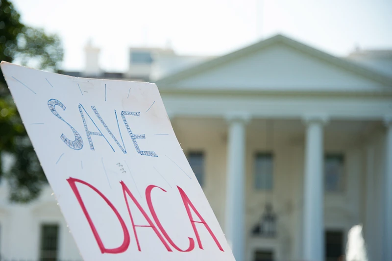 U.S. bishops warn of looming court order in Obama-era immigration program #Catholic 
 
 A DACA protest sign is waved outside of the White House. / null

CNA Staff, Oct 18, 2025 / 09:00 am (CNA).
The U.S. Conference of Catholic Bishops (USCCB) released an update this week on the Deferred Action for Childhood Arrivals (DACA) program highlighting the threat a looming court order may pose to the legal privileges of some immigrants in Texas.Immigrants covered by DACA who move to or from Texas could quickly face the loss of their work authorization under the new court order, according to the bishops' Department of Migration and Refugee Services.Launched in 2012 through executive action by then-President Barack Obama, DACA offers work authorization and temporary protection from deportation to undocumented immigrants brought to the U.S. as minors. The first Trump administration tried to end the program but was blocked from doing so in 2020 by the U.S. Supreme Court. While President Donald Trump has indicated a willingness to work with Democrats on the status of DACA beneficiaries, the program continues to be subject to litigation, with the latest developments centering on the Texas v. United States case.In that case, Texas sued the federal government claiming that DACA was illegally created without statutory authority, as it was formed through executive action rather than legislation passed by Congress.In January, the Fifth Circuit Court of Appeals largely upheld the U.S. district court’s declaration that DACA is unlawful, but narrowed the scope to Texas, separating deportation protections from work authorization. This means, in theory, that DACA's core shield against removal could remain available nationwide for current recipients and new applicants, while work permits might be preserved for most — except in Texas. Impending implementation The USCCB's Oct. 14 advisory comes as the district court prepares to implement the ruling upheld by the appeals court. On Sept. 29 the U.S. Department of Justice issued guidance concerning how the order should be implemented. Andrew Arthur, a former immigration judge and a fellow at the Center for Immigration Studies, told CNA that the key takeaway from the USCCB’s update is a “warning” to DACA recipients “who live in Texas.”"[A]nyone who has DACA or is eligible to receive it would need to consider the implications of moving to or from Texas," the USCCB update states, pointing out that relocation could trigger revocation of employment authorization with just 15 days' notice. For Texas's approximately 90,000 DACA recipients — the second-largest population after California's 145,000 — the implications could be stark, according to the bishops. Under the order, if it is implemented according to the U.S. government’s proposals, DACA recipients who live in Texas could receive "forbearance from removal" (deferred deportation) but lose "lawful presence" status, disqualifying them from work permits and benefits like in-state tuition or driver's licenses. To be eligible for DACA, applicants must have arrived before age 16, resided continuously since June 15, 2007, and been under the age of 31 as of June 15, 2012. There are approximately 530,000 DACA participants nationwide according to KFF, formerly the Kaiser Family Foundation. The KFF estimates that up to 1.1 million individuals meet DACA eligibility criteria.