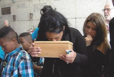 Burials for little ones: How a New Orleans ministry helps families grieve #Catholic 
 
 A family grieves their lost baby at a funeral at the crypt at St. Patrick’s Cemetery in New Orleans. Many friends, relatives, and families attended the funeral that day. / Credit: Photo courtesy of Compassionate Burials for Indigent Babies

CNA Staff, Nov 19, 2025 / 06:00 am (CNA).
Sandy Schaetz still mourns the baby she never met. “It was terrifying and traumatic,” she said of her miscarriage. “I was consoled after by the prayers of a deacon, but never named the baby or knew if it was a boy or girl.” “It was not something I understood at the time and I only wish I had known more of what was happening,” she told CNA. Now, Schaetz volunteers with Compassionate Burials for Indigent Babies (CBIB), an organization that buries babies who died, whether stillborn, miscarried, or aborted.The group organizes everything for the funerals, which are held at a crypt at St. Patrick’s Cemetery in New Orleans.A shoebox-sized casket lined with donated white fabric, usually from wedding dresses, is processed through the cemetery, with Knights of Columbus present as the honor guard. A volunteer musician plays at every funeral; a Catholic deacon presides at almost every burial.Two Knights of Columbus carry the casket of a baby who was murdered. Credit: Photo courtesy of Compassionate Burials for Indigent BabiesWhen Schaetz attended her first burial service as a volunteer, it hit her to the core.  “I find it difficult to put into words how it affected me,” Schaetz said. “All God needed me to do that day was to be present, to pray, to honor the life he had created.” “It opened my eyes to how each life is such a gift, and when that life ends how important it is to show respect and pray for the soul and bury the dead with love,” Schaetz said. Death and resurrection Women who lose children through miscarriage often suffer silently, according to Lise Naccari, the founder of CBIB. “Losing a child is hard. Often women suffer in silence the pain of infant loss and ride that sad emotional roller coaster ride alone,” Naccari told CNA. One in four pregnancies ends in miscarriage — a devastating statistic for many couples. Naccari herself experienced a miscarriage as well as several challenging pregnancies. “I feel a special connection with poor mothers who have lost a child. My heart goes out to them,” Naccari said.Lise Naccari (right) embraces a grieving mother at a burial at the crypt at St. Patrick’s Cemetery in New Orleans. Credit: Photo courtesy of Compassionate Burials for Indigent BabiesNaccari buries the babies who were wanted and loved, but also the babies who were thrown out or mistreated.“CBIB has buried babies as big as a blueberry and up to 2 years old,” Naccari said. “We buried babies stillborn, miscarried, abandoned, unclaimed, aborted, murdered, and thrown away in the trash — and every situation possible.”“Many babies were mistreated, abused, and tossed out … these are heartbreaking funerals to go to,” Naccari said.CBIB dressed and buried seven babies who were left at hospitals labeled “unclaimed and abandoned,” Naccari said. CBIB buried the babies at the crypt at St. Patrick’s Cemetery in New Orleans. Credit: Photo courtesy of Compassionate Burials for Indigent Babies“Babies are left sometimes because some families can not afford funerals for them but would like one,” Naccari said. “Also, many parents are young, and the grief can be overwhelming and they cannot navigate through funeral arrangements.” Her life’s work is to bury the dead — and she looks to the Resurrection. “I consider what I do holy,” Naccari said. “I feel like this is my vocation and I know God orchestrated all of this. I give all honor and glory to him, our loving Father.” “What I do is not about sorrow and death,” Naccari continued. “What I do is really about joy and life — eternal life.” A father (right) whose child was murdered carries the casket with the help of others. Credit: Photo courtesy of Compassionate Burials for Indigent BabiesIt’s not an easy job, and Naccari looks to God for strength.“Lord, I don’t want to do this anymore. It hurts my heart too much,” Naccari remembered praying as she prepared one baby for burial — a baby girl who had been abandoned and tossed out after she was born.“I felt a still small voice within me say, ‘Lise, don’t think about their bodies, focus on the Resurrection,’” Naccari recalled.“The sunlight from the stained-glass windows was shining down a warm yellow color on my face, as I looked up in it and I thought, yes, this is what I needed to hear to keep going — focus on the Resurrection,” she continued.A resource for women in needSheena Lewis was in jail when her son, still a baby, passed away. She couldn’t attend the funeral, but Naccari organized the burial for her.Lewis, now sober and out of jail, visits her son’s crypt often.“I have solace in the fact he was laid to rest in a beautiful manner when I couldn’t be there for him or myself at the time,” Lewis told CNA.Many young mothers CBIB helps are often “steeped in poverty” and have no support system. They are often “low income, uneducated, coming from sometimes addiction or problem homes,” Naccari said.“Often I find at these funerals that the young mothers are alone or they may come with children or other women — but there are no men to help support them,” Naccari said.“My heart is broken for them, for they are not only battling their poverty, they also have to deal with losing a child,” she said.A moment to mourn Funerals help families process their grief — a grief that’s often hidden away due to the nature of miscarriages. Deacon Ricky Suprean preaches at almost every graveside burial — but after a couple years of volunteering, he realized God had called him to this so he could find healing. Suprean and his wife, Lynn, experienced two miscarriages.Suprean struggled to process it at the time, but through his volunteering, he’s found some healing. He still remembers the first CBIB funeral he presided at. “I felt the power of life that day,” he told CNA. “It was cold. I had no idea I would kneel in front of each little coffin and pray for each child and each family with my hand touching each coffin.”Volunteers hugged each family member, he recalled.Deacon Ricky Suprean at the burial of two babies at the crypt at St. Patrick’s Cemetery in New Orleans. Credit: Photo courtesy of Compassionate Burials for Indigent Babies“God has allowed me to give a proper burial to my own two lost children through CBIB time and time again,” Suprean said.“God created these children in my wife’s womb, and they will be waiting for us in heaven,” Suprean continued.Struggling to process grief is common with loss of children, according to Naccari.“Too often people are hurting so much and don’t want to face a funeral,” Naccari said. “They feel vulnerable and so it is easier to turn away and do nothing.”“But on the contrary, I have observed that these funerals provide consolation, comfort, solace, and even a healthy way of healing after the loss of a baby,” Naccari said.“It’s a good grief,” Naccari continued. “Funerals are about love and holding onto friends and family at a time of need. It can be life-changing.”Some funerals have had as many as 100 people in attendance.Many volunteers are “faithfully committed” to being present at every funeral.“It could be freezing cold or blistering hot in the summer, but they just show up and either help set up, greet the parents, or stand tall next to a casket to show the love of Jesus to our families,” Naccari said.The altar at a burial at the crypt at St. Patrick’s Cemetery in New Orleans. CBIB has buried hundreds of babies at the crypt. Credit: Photo courtesy of Compassionate Burials for Indigent BabiesThese funerals “allow parents that special moment to mourn their loss and to remember their little one and ponder the person that little one could have been,” Naccari said.“CBIB celebrates each life, and we believe that God somehow rights all the wrongs and makes all things new,” Naccari said. “And then we move to the next funeral.”