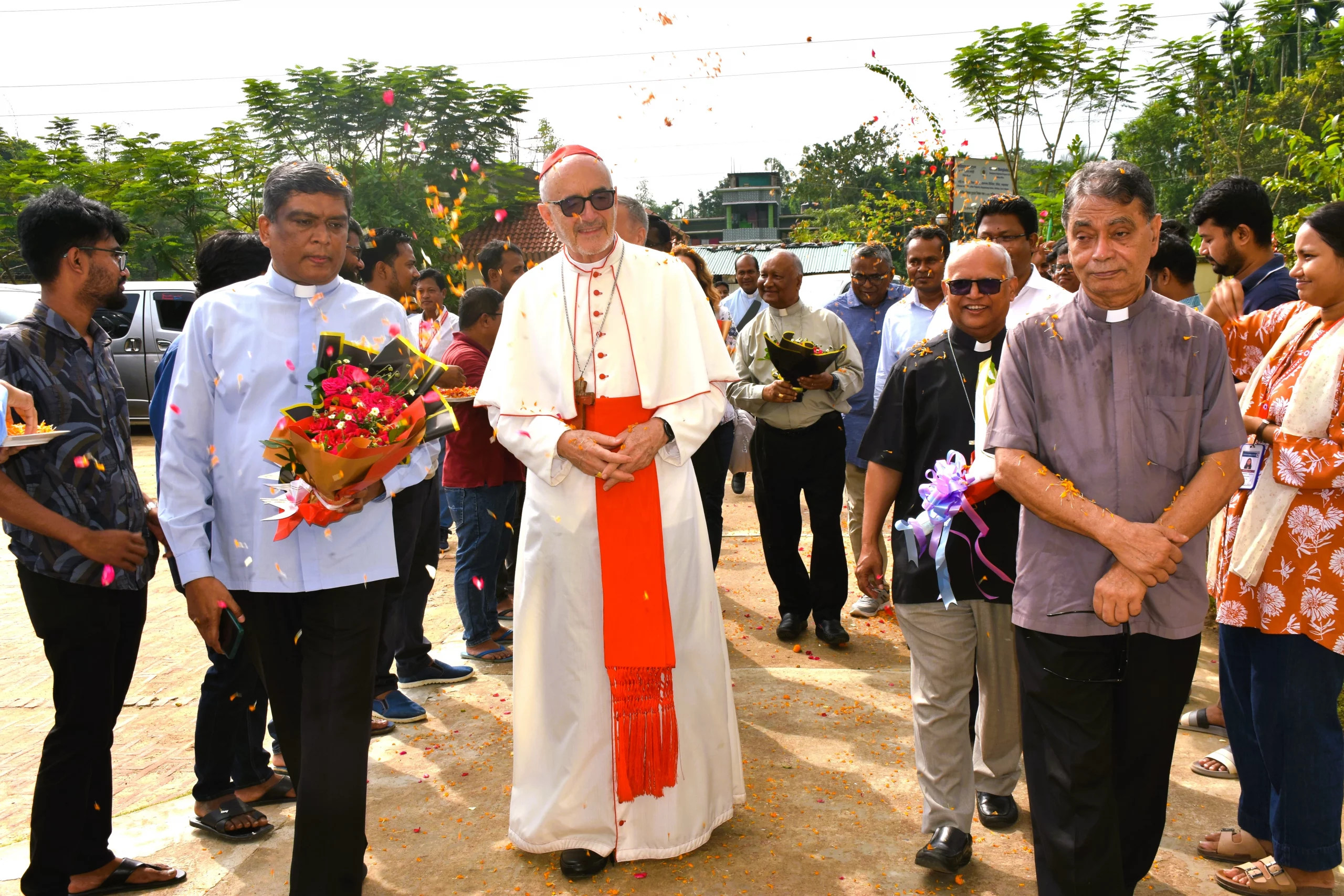 Cardinal Czerny brings message of hope to Rohingya in Bangladesh – #Catholic –
Cardinal Michael Czerny, SJ, receives flowers from Rohingya during his visit to Cox’s Bazar, considered the world’s largest refugee camp, on Sunday, Nov. 3, 2025. / Credit: Caritas Bangladesh
Dhaka, Bangladesh, Nov 9, 2025 / 07:00 am (CNA).
Cardinal Michael Czerny, SJ, prefect of the Dicastery for Promoting Integral Human Development, concluded a five-day pastoral visit with migrants and displaced Catholics under the theme “Raising Hope to Foster a Culture of Care.”From Nov. 1–5, Czerny met with internally displaced Catholics near Dhaka and visited Rohingya in Cox’s Bazar, highlighting urgent issues of migration, poverty, and social justice.Bangladesh hosts two vulnerable communities: approximately 50,000 internally displaced Catholics in Dhaka and Narayanganj, and nearly 1.1 million Rohingya refugees and migrants in Cox’s Bazar — considered the largest refugee camp in the world.The visit sought to affirm the Church’s solidarity with these groups and encourage collaboration among Church leaders, government agencies, and humanitarian organizations.Message of faith for displaced CatholicsOn Nov. 2, Czerny celebrated Mass with more than 600 Catholics in Modonpur, Narayanganj, an industrial area where many migrants from rural Bangladesh live in precarious conditions. Many have fled their ancestral villages seeking better livelihoods, often working in factories under difficult circumstances.“You are poor, but you gather to worship God,” Czerny told the faithful. “As you pray, God will answer your prayers. You will be blessed.”For Sujon Das, 28, a machine operator originally from Thakurgaon, the encounter was deeply moving. “Cardinal Czerny admired us,” Das told CNA. “I had night duty on Nov. 3, but after work I joined the Mass. Normally we cannot attend Sunday Mass because we only get Fridays off — and sometimes we work even then.”Das recalled a painful memory: “On Aug. 5, 2024, during political unrest, miscreants set fire to our church. Still, we keep our faith.” The violence occurred during widespread unrest following the resignation of Prime Minister Sheikh Hasina, which resulted in attacks on religious minorities across Bangladesh.Father Ajit Victor Costa, who ministers regularly in Modonpur, explained why so many Catholics migrate to the area. “For existential reasons and better livelihood, they come to industrial zones seeking jobs,” he explained. “Most are landless and worked as day laborers in villages, earning very little. Migration continues, and many families remain separated.”During his homily, Czerny praised those who serve migrants and refugees: “Communities that welcome migrants can be a living witness to hope — a promise of a present and future where the dignity of all as children of God is recognized.”Cardinal Michael Czerny, SJ, meets with Rohingya in Cox’s Bazar on Sunday, Nov. 3, 2025. Credit: Caritas BangladeshSolidarity with RohingyaOn Nov. 3, Czerny traveled to Cox’s Bazar to visit Rohingya who fled violence in Myanmar.During a tour of Caritas Bangladesh’s humanitarian programs, he expressed concern about dwindling global support.“The situation is very difficult, with funding cuts and less attention from the world,” Czerny said during his visit to the migrant camp. “The world should show more solidarity, not less. All organizations — Christian and others — must respond to real needs and continue to support those who suffer.”Czerny assured them of the Church’s commitment. “I hope one day you can return safely to your homeland and live in peace and dignity,” he said.Abdul Rahman (not his real name), 55, a Rohingya refugee, voiced gratitude. “Caritas Bangladesh stands with us, offering love and care — clean water, sanitation, shelter, and hope,” Rahman said. “Even when the world forgets, Caritas remains close.”CNA is using pseudonyms for Rohingya refugees at their request for security reasons.Children welcomed the visitor from the Vatican with songs and drawings. “Please help us with more play and learning materials,” said Mohammad Nur (not his real name). Czerny called their joy “a sign of hope and life that inspires us all to keep serving with compassion.”Justice and peace at the heart of missionOn Nov. 4 in Dhaka, Czerny inaugurated the 50th anniversary of the Episcopal Commission for Justice and Peace of Bangladesh, praising its work on human rights, child protection, climate change, migration, and anti-trafficking efforts.He also visited children in drug rehabilitation centers, orphanages, and migrant shelters. “The care you receive is good,” he told them, “but think also about what kind of service you can offer to others.”At a press conference later that day, Czerny reflected on the challenges facing both communities. “For those in the camps, being stateless, unemployed, and confined for years is intolerable,” he said. “The international community has not been able to provide a solution to the Rohingya crisis, and that needs to change.”Call to actionCzerny’s visit underscored the Church’s mission to accompany those on the margins.“The Holy Spirit sends us to others,” he reminded the faithful. “The care you bring to migrants and refugees is a trace of the Spirit — a sign of salvation and hope.”Archbishop Bejoy N. D’Cruze of Dhaka, president of the Catholic Bishops’ Conference of Bangladesh, expressed his gratitude to Czerny for the pastoral visit.“I am confident that this visit will be a blessing for the Catholic Church in Bangladesh,” D’Cruze said. “I believe it will further inspire and strengthen our commitment to inclusive human development.” Cardinal Czerny brings message of hope to Rohingya in Bangladesh – #Catholic –
Cardinal Michael Czerny, SJ, receives flowers from Rohingya during his visit to Cox’s Bazar, considered the world’s largest refugee camp, on Sunday, Nov. 3, 2025. / Credit: Caritas Bangladesh
Dhaka, Bangladesh, Nov 9, 2025 / 07:00 am (CNA).
Cardinal Michael Czerny, SJ, prefect of the Dicastery for Promoting Integral Human Development, concluded a five-day pastoral visit with migrants and displaced Catholics under the theme “Raising Hope to Foster a Culture of Care.”From Nov. 1–5, Czerny met with internally displaced Catholics near Dhaka and visited Rohingya in Cox’s Bazar, highlighting urgent issues of migration, poverty, and social justice.Bangladesh hosts two vulnerable communities: approximately 50,000 internally displaced Catholics in Dhaka and Narayanganj, and nearly 1.1 million Rohingya refugees and migrants in Cox’s Bazar — considered the largest refugee camp in the world.The visit sought to affirm the Church’s solidarity with these groups and encourage collaboration among Church leaders, government agencies, and humanitarian organizations.Message of faith for displaced CatholicsOn Nov. 2, Czerny celebrated Mass with more than 600 Catholics in Modonpur, Narayanganj, an industrial area where many migrants from rural Bangladesh live in precarious conditions. Many have fled their ancestral villages seeking better livelihoods, often working in factories under difficult circumstances.“You are poor, but you gather to worship God,” Czerny told the faithful. “As you pray, God will answer your prayers. You will be blessed.”For Sujon Das, 28, a machine operator originally from Thakurgaon, the encounter was deeply moving. “Cardinal Czerny admired us,” Das told CNA. “I had night duty on Nov. 3, but after work I joined the Mass. Normally we cannot attend Sunday Mass because we only get Fridays off — and sometimes we work even then.”Das recalled a painful memory: “On Aug. 5, 2024, during political unrest, miscreants set fire to our church. Still, we keep our faith.” The violence occurred during widespread unrest following the resignation of Prime Minister Sheikh Hasina, which resulted in attacks on religious minorities across Bangladesh.Father Ajit Victor Costa, who ministers regularly in Modonpur, explained why so many Catholics migrate to the area. “For existential reasons and better livelihood, they come to industrial zones seeking jobs,” he explained. “Most are landless and worked as day laborers in villages, earning very little. Migration continues, and many families remain separated.”During his homily, Czerny praised those who serve migrants and refugees: “Communities that welcome migrants can be a living witness to hope — a promise of a present and future where the dignity of all as children of God is recognized.”Cardinal Michael Czerny, SJ, meets with Rohingya in Cox’s Bazar on Sunday, Nov. 3, 2025. Credit: Caritas BangladeshSolidarity with RohingyaOn Nov. 3, Czerny traveled to Cox’s Bazar to visit Rohingya who fled violence in Myanmar.During a tour of Caritas Bangladesh’s humanitarian programs, he expressed concern about dwindling global support.“The situation is very difficult, with funding cuts and less attention from the world,” Czerny said during his visit to the migrant camp. “The world should show more solidarity, not less. All organizations — Christian and others — must respond to real needs and continue to support those who suffer.”Czerny assured them of the Church’s commitment. “I hope one day you can return safely to your homeland and live in peace and dignity,” he said.Abdul Rahman (not his real name), 55, a Rohingya refugee, voiced gratitude. “Caritas Bangladesh stands with us, offering love and care — clean water, sanitation, shelter, and hope,” Rahman said. “Even when the world forgets, Caritas remains close.”CNA is using pseudonyms for Rohingya refugees at their request for security reasons.Children welcomed the visitor from the Vatican with songs and drawings. “Please help us with more play and learning materials,” said Mohammad Nur (not his real name). Czerny called their joy “a sign of hope and life that inspires us all to keep serving with compassion.”Justice and peace at the heart of missionOn Nov. 4 in Dhaka, Czerny inaugurated the 50th anniversary of the Episcopal Commission for Justice and Peace of Bangladesh, praising its work on human rights, child protection, climate change, migration, and anti-trafficking efforts.He also visited children in drug rehabilitation centers, orphanages, and migrant shelters. “The care you receive is good,” he told them, “but think also about what kind of service you can offer to others.”At a press conference later that day, Czerny reflected on the challenges facing both communities. “For those in the camps, being stateless, unemployed, and confined for years is intolerable,” he said. “The international community has not been able to provide a solution to the Rohingya crisis, and that needs to change.”Call to actionCzerny’s visit underscored the Church’s mission to accompany those on the margins.“The Holy Spirit sends us to others,” he reminded the faithful. “The care you bring to migrants and refugees is a trace of the Spirit — a sign of salvation and hope.”Archbishop Bejoy N. D’Cruze of Dhaka, president of the Catholic Bishops’ Conference of Bangladesh, expressed his gratitude to Czerny for the pastoral visit.“I am confident that this visit will be a blessing for the Catholic Church in Bangladesh,” D’Cruze said. “I believe it will further inspire and strengthen our commitment to inclusive human development.”
