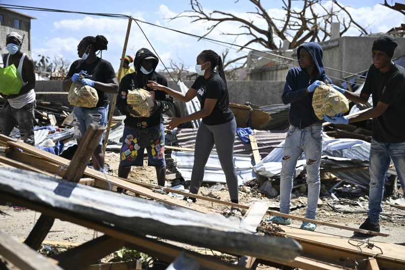 Catholics mobilize in Caribbean following Category 5 hurricane  #Catholic 
 
 Residents help move food supplies at a community center before distribution to the Whitehouse community in Westmoreland, Jamaica, one of the areas most severely affected by the passage of Hurricane Melissa, on Nov. 2, 2025. / Credit: Ricardo Makyn/AFP via Getty Images

Washington, D.C. Newsroom, Nov 6, 2025 / 14:15 pm (CNA).
Catholic leaders and agencies have mobilized to help communities left devastated after Hurricane Melissa hit Jamaica.The Category 5 hurricane swept through the Caribbean with sustained winds of 185 miles per hour and claimed up to 50 lives after making landfall on Oct. 28. Jamaica suffered the largest impact, but neighboring nations also experienced immense effects including flash flooding and landslides.In Jamaica, practically no buildings along the country’s southern coast remain intact. Areas have experienced structural failures, immense roof damage, floods, power outages, and communication disruptions. Families have a long road to recovery after many lost loved ones, property, possessions, and livelihoods.To help communities suffering from Hurricane Melissa’s aftermath, Catholic agencies are on the ground supporting relief efforts and fundraising across the globe to provide aid. Providing aid Dominican friars with St. Martin’s Missions, an initiative that supports communities in Jamaica and Grenada, are working to help communities most affected. Father Bede Mullens, OP, one of the friars working in Jamaica, told CNA they are based in Kingston, “which mercifully was left largely unscathed by the hurricane.”“Nonetheless, some of our poorer parishioners in August Town, an impoverished neighborhood, did lose roofs, walls, and in one case pretty much the whole house,” Mullens said. With the help of donations from across the globe, St. Martin’s will purchase and provide materials for repairs and food.Mullens explained that “after recent panic-buying, some food items are hard to come by, and food prices on the whole are set to go up in the coming months, as the part of the island hardest hit is a major agricultural area.”This Friday, Nov. 7, the friars will distribute 300 meals to students at the University of the West Indies in Mona, Jamaica, and to several less-well-off parishioners. Mullens said: “We are trying to arrange sponsorship from local benefactors for students in need to receive support for food and personal hygiene items.”Across the island the friars have been able to contact some parishes near Montego Bay, which suffered great damage. “One of the churches is currently operating as a shelter with just half a roof,” Mullens said.The friars have also coordinated provisions of basic building materials and essentials including water and baby food that will be transported to Sacred Heart Church near Montego Bay and St. Agnes Church in Chester Castle.When the roads reopen and the friars are able to make contact with more parishes in other areas, they plan to also assist their rebuilding efforts and support the local community needs.“There is, of course, a massive need for material assistance, but for us it is very important that St. Martin’s bears witness to our worldwide solidarity in the body of Christ,” Mullens said. “We belong to a Church that is at once truly Catholic and truly one, at once global and personal.”Franciscan Friars Charities (FFC), the charitable arm of the Province of Our Lady of Guadalupe, activated the Franciscan Relief Fund to help the people in western Jamaica recover from extensive damage.“The friars in Negril have quickly mobilized to assess the community’s needs after the storm,” FFC said in a statement. “Each day they ground their hearts in faith through morning prayer and daily Mass before heading out into the community to provide vital services.”The friars are serving warm meals daily at St. Anthony Kitchen, a soup kitchen in Negril. They anticipate a significant increase in the number of people coming to the kitchen, expecting approximately 400 to 500 people a day.The friars are cleaning the Revival Health Clinic, which provides basic medical care, and are looking into creating a mobile clinic to visit remote areas. They are also visiting parishioners, many of whom have lost their homes, and providing them with immediate relief including water and food.“Communicating with our friars in Negril has been difficult because there’s no electricity and the cellular services are down,” said Brother Jim Bok, OFM. “There’s just unbelievable destruction. It’s going to take years to recover. A tremendous amount of outside support will be needed to help deal with it.”Organizations respond with action Hospital Sisters Mission Outreach, an Illinois-based organization that partners with organizations, hospitals, and clinics around the world, is working directly with Food for the Poor and other organizations transporting and distributing aid.After learning there was an urgent need for diapers, Mission Outreach’s warehouse team mobilized to send out 4,000 it had available. It also shipped out a 40-foot container to Jamaica filled with requested medical supplies and equipment.A number of Catholic relief organizations including Cross Catholic Outreach (CCO) and Catholic Relief Services (CRS) are fundraising to send food, medicines, and housing supplies to ministry partners in Jamaica, the Dominican Republic, Haiti, and Cuba.CCO said it is “sending shipments of recovery supplies to the Compassionate Franciscan Sisters of the Poor and will airlift medical supplies into Montego Bay when conditions are safe enough to do so.” It is also working to help the Diocese of Mandeville to rebuild St. Theresa Kindergarten, which was destroyed in the storm.CRS is working to help on the ground with “a team of 100 staff in Haiti and local partners in Jamaica and the region,” the organization reported. “CRS and the Catholic Church are committed to walking with families through every phase of recovery — from immediate relief to long-term rebuilding. ”The U.S. State Department’s Bureau of Western Hemisphere Affairs will coordinate with the Catholic Church to distribute  million in humanitarian assistance. The funds will go directly to helping those impacted in eastern Cuba by the devastation of Hurricane Melissa.