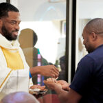 Former Florham Park priest’s encouragement leads to Divine Word vocation #Catholic – From a grandmother’s lips to God’s ears! Early on, Paulina Macarthy had a hunch about her grandson, Ryan Agbim. When he was 3 years old, she declared, “Ryan is going to be a priest one day.”
Perhaps it was God who first whispered into Macarthy’s ears. Agbim, now 30, formerly of Holy Family Parish in Florham Park, N.J., has since heard — and answered — the Lord’s call. He is preparing to be ordained a priest of the Society of the Divine Word in Chicago, Ill., on May 23, 2026. The seeds of that vocation were first sown in the Paterson Diocese in New Jersey.
Agbim and six other Divine Word Missionaries took their final step toward the priesthood on Oct. 12, when they were ordained to the temporary diaconate at Our Lady of Africa Parish in Chicago. He is now serving at the Shrine of Our Lady of Pompeii in that city as a deacon. Agbim expects to complete his priestly studies at Catholic Theological Union in Chicago before his ordination.
Click here to subscribe to our weekly newsletter.
“When I finish assisting or preaching at Mass as a deacon, I’m happy and smiling. It leaves me saying, ‘I could do this forever — but as a priest,” said Agbim, who admitted he is still getting used to being called “Deacon Ryan.”
From 2003 to 2014, Agbim and his family — his mother, Barbara, from England, and his father, Mathias, from Nigeria, both deceased, and his sister, Jessica — attended weekly Mass at Holy Family.
But it wasn’t until college that Agbim first heard God’s call through the questions of others, like “Have you thought of being a priest?” One of them was Bishop Emeritus Arthur J. Serratelli during a pastoral visit to Holy Family.
Initially, Agbim discerned a life with a wife and children. He earned a bachelor’s degree in public health from Rutgers University in New Brunswick, N.J., in 2018. But at the end of his sophomore year, he had a life-changing conversation with Father Fred Walters, then Holy Family’s pastor, now retired.
“Father Fred said, ‘As a priest, you could be a spiritual father for your spiritual children — to so many people,’” Agbim said. “That moved me from wanting to be a biological father to being a priest.”
Agbim’s exploration of vocations led him to the Society of the Divine Word. He was impressed by the community’s “missionary spirit.” Divine Word Missionaries work globally in 79 countries to spread the Gospel through service and action.
In 2019, Agbim quit his job as a pharmacy technician to enter Divine Word’s novitiate in Epworth, Iowa. He made his first vows in 2020 and his perpetual vows in 2025. He later moved to Hyde Park, Chicago, for theology studies.
Agbim’s many apostolic experiences have included hospital chaplaincy, migrant ministry, social justice, and prison ministry. He spent two years in Italy, first learning the language and culture in Padua. Then, he served a parish in Trent, focusing on pilgrimages, youth ministry, religious education, and a clothing and food drive.
“The parish welcomed this 6-foot black American and built a relationship with me like Jesus talks about. I cried the day I left,” Agbim said.
Agbim’s first assignment as a priest will be with the Chicago Province, which spans from Nebraska to Massachusetts and from Canada to the Caribbean. Divine Word priests and Father Walters inspire him. “Father Fred was always joyful, smiling, and at peace. I want that for my priesthood,” Agbim said.
Concerning his future vocation, Agbim said, “I feel gratitude, mixed with some fear. But I leave certain decisions in God’s hands. He knows better than I do.”
Former Florham Park priest’s encouragement leads to Divine Word vocation #Catholic – From a grandmother’s lips to God’s ears! Early on, Paulina Macarthy had a hunch about her grandson, Ryan Agbim. When he was 3 years old, she declared, “Ryan is going to be a priest one day.”
Perhaps it was God who first whispered into Macarthy’s ears. Agbim, now 30, formerly of Holy Family Parish in Florham Park, N.J., has since heard — and answered — the Lord’s call. He is preparing to be ordained a priest of the Society of the Divine Word in Chicago, Ill., on May 23, 2026. The seeds of that vocation were first sown in the Paterson Diocese in New Jersey.
Agbim and six other Divine Word Missionaries took their final step toward the priesthood on Oct. 12, when they were ordained to the temporary diaconate at Our Lady of Africa Parish in Chicago. He is now serving at the Shrine of Our Lady of Pompeii in that city as a deacon. Agbim expects to complete his priestly studies at Catholic Theological Union in Chicago before his ordination.
Click here to subscribe to our weekly newsletter.
“When I finish assisting or preaching at Mass as a deacon, I’m happy and smiling. It leaves me saying, ‘I could do this forever — but as a priest,” said Agbim, who admitted he is still getting used to being called “Deacon Ryan.”
From 2003 to 2014, Agbim and his family — his mother, Barbara, from England, and his father, Mathias, from Nigeria, both deceased, and his sister, Jessica — attended weekly Mass at Holy Family.
But it wasn’t until college that Agbim first heard God’s call through the questions of others, like “Have you thought of being a priest?” One of them was Bishop Emeritus Arthur J. Serratelli during a pastoral visit to Holy Family.
Initially, Agbim discerned a life with a wife and children. He earned a bachelor’s degree in public health from Rutgers University in New Brunswick, N.J., in 2018. But at the end of his sophomore year, he had a life-changing conversation with Father Fred Walters, then Holy Family’s pastor, now retired.
“Father Fred said, ‘As a priest, you could be a spiritual father for your spiritual children — to so many people,’” Agbim said. “That moved me from wanting to be a biological father to being a priest.”
Agbim’s exploration of vocations led him to the Society of the Divine Word. He was impressed by the community’s “missionary spirit.” Divine Word Missionaries work globally in 79 countries to spread the Gospel through service and action.
In 2019, Agbim quit his job as a pharmacy technician to enter Divine Word’s novitiate in Epworth, Iowa. He made his first vows in 2020 and his perpetual vows in 2025. He later moved to Hyde Park, Chicago, for theology studies.
Agbim’s many apostolic experiences have included hospital chaplaincy, migrant ministry, social justice, and prison ministry. He spent two years in Italy, first learning the language and culture in Padua. Then, he served a parish in Trent, focusing on pilgrimages, youth ministry, religious education, and a clothing and food drive.
“The parish welcomed this 6-foot black American and built a relationship with me like Jesus talks about. I cried the day I left,” Agbim said.
Agbim’s first assignment as a priest will be with the Chicago Province, which spans from Nebraska to Massachusetts and from Canada to the Caribbean. Divine Word priests and Father Walters inspire him. “Father Fred was always joyful, smiling, and at peace. I want that for my priesthood,” Agbim said.
Concerning his future vocation, Agbim said, “I feel gratitude, mixed with some fear. But I leave certain decisions in God’s hands. He knows better than I do.”