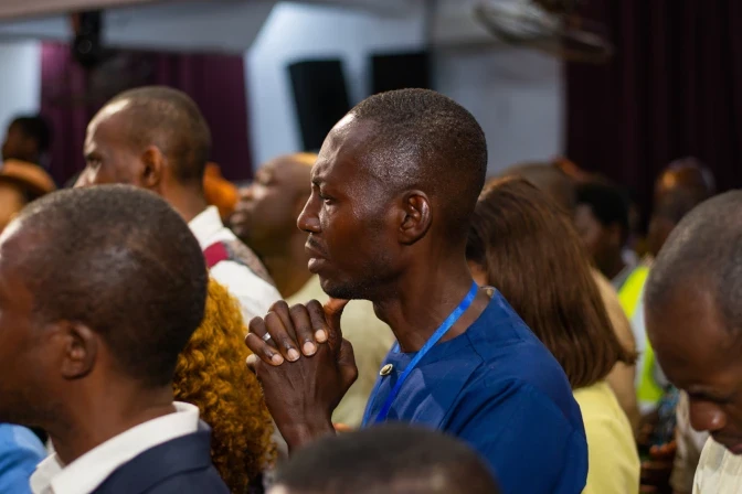 Hundreds of Nigerian students remain captive; Cameroon archbishop warns of church closures - #Catholic - 
 
 Parishioners at a church in Akute Ogun State, Nigeria, in June 11, 2023. / Credit: Ariyo Olasunkanmi/ Shutterstock

ACI Prensa Staff, Nov 24, 2025 / 17:41 pm (CNA).
The Catholic Church is facing a new wave of violence in Africa: In Nigeria, 265 students from a Catholic school remain captive after being kidnapped last week while an archbishop in Cameroon is threatening to close parishes if a kidnapped priest is not released.In Nigeria, Bishop Bulus Dauwa Yohanna of Kontagora told Fides: “The kidnappers are almost certainly criminals seeking illicit gain by demanding a ransom.”An official statement from the diocese, published on Nov. 23, reported that 50 minors managed to escape and reunite with their families after fleeing between Friday and Saturday following the attack. These developments were confirmed through visits and phone calls with their relatives, the statement said.However, of the 315 people initially captured, “265 remain in the hands of the kidnappers, of whom 239 are children, 14 are high school students, and 12 are members of the school staff,” the diocesan statement specified.The institution serves 430 primary school students (377 boarders and 53 day students) and 199 secondary school students, figures that, according to the diocese, “are important in helping the public understand the scale of the incident and the extensive efforts underway to account for every missing child and staff member.”Cameroon archbishop demands release of kidnapped priestThe archbishop of Bamenda, Andrew Nkea Fuanya, announced that “if Father John is not released before Nov. 26, the churches in the deanery will be closed” as a measure to pressure for the release of parish priest John Berinyuy Tatah, who was kidnapped on Nov. 15 by armed men in northeastern Cameroon along with his vicar.The faithful were informed of the possible closures in an official message read on Sunday, Nov. 23, in all parishes, the Vatican news agency Fides reported.Nkea explained that if the priest remains in the hands of his captors by that date, the parishes, schools, and Catholic institutions of the Ndop deanery will be closed. “Priests will be evacuated for their safety, and the Blessed Sacrament will be removed from the churches.”Furthermore, he warned that if the priest continues to be held captive on Nov. 28, the archbishop, the clergy, and lay faithful will march to the village of Baba I, where he is believed to be held, “and will either bring him back home or remain there until he is released,” Fides reported.The prelate denounced the frequent kidnappings of priests and pastoral workers, stating that the perpetrators “have put us against the wall, and all of this must end immediately,” noting that many laypeople have also suffered torture, violence, and extortion.According to Fides, the kidnapping was carried out by armed separatists who have proclaimed the so-called “Republic of Ambazonia” in the English-speaking northeast and southeast regions of the country. The rest of Cameroon is French-speaking.Bishop Barron: ‘The persecution is real and we must react’The situation in Nigeria has caused international outrage. The bishop of Winona-Rochester in Minnesota, Robert Barron, recently referred to the wave of attacks against Catholic communities, noting that what has happened is part of “an ongoing and long-standing persecution.”“Over the last 10 years, I think 100,000 Christians have been murdered, tens of thousands of churches burned, [and there has been a] huge displacement of the Christian population,” he said on X.After explaining that in the middle parts of the country the attacks on Christians may be motivated by a mixture of religious, tribal, or economic reasons, Barron said he did not want the appeal to mixed motives as an excuse for inaction.“Are the motives of the persecutors mixed? Sure, I’ll grant you that. There are economic or tribal elements, of course. But my overall point is: Who cares? What matters here is that our brother and sister Christians are being brutally mistreated.”Barron also appealed to the international Christian community: “Our connections in Christ to one another are deeper than our national identity.” Christians must pray, speak out, raise awareness, and ask our representatives to act, he said.The bishop also emphasized that Nigeria today is “a flourishing Church” in vocations and vitality. “Am I surprised that that Church especially is undergoing a very vicious persecution? No. The more successful a Church becomes, the more on fire with Christ it becomes, the more it attracts the attention of the enemy.”Call for calm and prayerThe Diocese of Kontagora assured that it is “fully committed to the safe rescue of those still in captivity” and reported that it continues to work with the police, authorities, and families.It also asked the faithful to remain calm, continue praying, and support the ongoing efforts.Meanwhile, in Cameroon, Nkea once again called on the authorities to stop the abuses against the population and demanded that the priest and all kidnapping victims be returned home as soon as possible.This story was first published by ACI Prensa, CNA’s Spanish-language news partner. It has been translated and adapted by CNA.