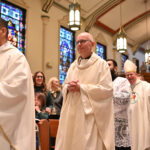 It’s official! New pastor installed at Chatham parish #Catholic - St. Patrick Parish in Chatham, N.J., gathered with great joy on Nov. 1 as Bishop Kevin J. Sweeney installed Father Peter Steven Glabik as the faith community’s new pastor. The bishop appointed Father Glabik as pastor, effective Sept. 1.
Father Glabik previously was pastor of St. Clare Parish in Clifton, N.J. He is currently the vice chair of the Presbyteral Council and vice chair of the College of Consultors for the Paterson Diocese in New Jersey.
Bishop Sweeney celebrated the Mass, which was concelebrated by several priests, including Father Robert Mitchell, a retired diocesan priest, former pastor of St. Patrick’s, and current temporary administrator of St. Rose of Lima Parish in East Hanover, N.J.

Click here to subscribe to our weekly newsletter.

On Oct. 31, 2007, Bishop Emeritus Arthur J. Serratelli ordained Father Glabik to the diocesan priesthood. Born on Feb. 27, 1976, in Brooklyn, N.Y., Father Glabik first studied with the Vincentians, Congregation of the Mission, from 1998 to 2003, and professed first vows, but then discovered his call to the diocesan priesthood.
Father Glabik earned a bachelor’s degree in religion at Niagara University, Niagara Falls, N.Y., and a master’s degree in theology at the Seminary of the Immaculate Conception, Huntington, N.Y. He completed priestly studies at Immaculate Conception Seminary, South Orange, N.Y.
As a priest of the diocese, Father Glabik served his first assignment as a part-time parochial vicar of St. Cecilia Parish and Sacred Heart parishes, both in Rockaway, N.J., while also serving as part-time campus minister at Morris Catholic High School in Denville, N.J. In 2009, he became a full-time parochial vicar of St. Cecilia’s and Sacred Heart.
The following year, Father Glabik was named the temporary priest-secretary to Bishop Serratelli and the diocesan vice chancellor and master of ceremonies. He began pursuing postgraduate studies at the former Ss. Cyril & Methodius Seminary in Orchard Lake, Mich., in 2011.
In 2012, Father Glabik was appointed administrator of St. Catherine of Bologna Parish in Ringwood, N.J., and later that year became pastor. He was named pastor of St. Clare’s in 2015.
In the diocese, Father Glabik also served as dean of northern Passaic, vocations director for recruitment, a member of the Clergy Personnel Board, and Clifton dean.
On social media, St. Patrick School posted, “May God bless Father Peter as he guides our parish and school with wisdom and grace.”
BEACON PHOTOS | JOE GIGLI
 [See image gallery at beaconnj.org]  