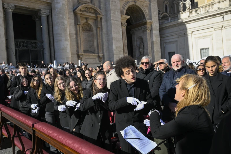 Liturgical singing requires 'a deep spiritual life,' Pope Leo XIV says – #Catholic – 
 
 A celebration of liturgical music is the focus of the Jubilee Mass Nov. 23, 2025. / Credit: Vatican Media

Rome Newsroom, Nov 23, 2025 / 13:10 pm (CNA).
Pope Leo XIV on Sunday praised the “precious” ministry of liturgical music and told choir members from around the world that their service at the altar must be sustained above all by a deep life of prayer. He later used his pre-Angelus remarks to appeal for the release of hostages kidnapped in Nigeria and Cameroon and to encourage young people on World Youth Day. The pope celebrated Mass in St. Peter’s Square for the Jubilee of Choirs on the Solemnity of Christ the King, telling choristers and musicians that their vocation is to lead God’s people into the mystery of worship. “Dear choristers and musicians, today you celebrate your jubilee and you show thanks to the Lord for granting you the gift and grace to serve him by offering your voices and talents for his glory and for the spiritual edification of your brothers and sisters,” he said in his homily. “Your task is to draw others into the praise of God and to help them to participate more fully in the liturgy through song.” ‘A true ministry’ rooted in prayer Drawing on the day’s responsorial psalm, “Let us go rejoicing to the house of the Lord” (Psalm 122), Pope Leo said the liturgy calls Christians “to walk together in praise and joy toward the encounter with the Lord Jesus Christ, King of the Universe, gentle and humble Sovereign.” “His power is love, his throne the Cross, and through the Cross his Kingdom shines forth upon the world,” he said. “From the wood he reigns as Prince of Peace and King of Justice who, in his Passion, reveals to the world the immense mercy of God’s heart. This love is also the inspiration and motive for your singing.” Pope Leo described singing as a uniquely human way of expressing what words alone cannot say. “Music can give expression to the whole range of feelings and emotions that arise within us from a living relationship with reality,” he said, adding that “singing, in particular, constitutes a natural and refined expression of the human being: mind, feelings, body and soul come together to communicate the great events of life.” Quoting St. Augustine, he recalled that “ ‘Cantare amantis est’ … that is, ‘singing belongs to those who love.’” For Christians, he continued, liturgical song is more than performance. “For the people of God, song expresses invocation and praise,” he said. “Liturgical music thus becomes a precious instrument through which we carry out our service of praise to God and express the joy of new life in Christ.” The pope underlined that choir members exercise a genuine ecclesial service, especially in the liturgy. “You belong to choirs that carry out their ministry primarily in liturgical settings. Yours is a true ministry that requires preparation, commitment, mutual understanding and, above all, a deep spiritual life, so that when you sing, you both pray and help everyone else to pray,” he said. This ministry, he added, “requires discipline and a spirit of service, especially when preparing for a solemn liturgy or an important event in your communities.” A ‘small family’ within the larger community Pope Leo urged choristers not to see themselves as performers set apart from the congregation, but as part of the praying assembly. “The choir is a small family of individuals united by their love of music and the service they offer. However, remember that the community is your larger family,” he said. “You are not on stage, but rather a part of that community, endeavoring to help it grow in unity by inspiring and engaging its members.” He acknowledged the ordinary tensions that can arise in any group, but said that even these can become a sign of the Church’s pilgrimage through history. “We can say to some extent that the choir symbolizes of the Church, which, striving toward its goal, walks through history praising God,” he said. “Even when this journey is beset by difficulties and trials and joyful moments give way to more challenging ones, singing makes the journey lighter, providing relief and consolation.” Citing both St. Augustine and St. Ignatius of Antioch, the pope presented the choir as a sign of synodality and unity in the Church, in which diverse voices become a single hymn of praise. “In fact, the different voices of a choir harmonize with each other, giving rise to a single hymn of praise, a luminous symbol of the Church, which unites everyone in love in a single pleasing melody,” he said. ‘Without giving in to the temptation of ostentation’ Pope Leo also encouraged musicians to study the Church’s teaching on sacred music and to resist the impulse to draw attention to themselves rather than to God. “Strive, therefore, to make your choirs ever harmonious and beautiful, and a brighter image of the Church praising her Lord,” he said. “Study the Magisterium carefully. The conciliar documents set out the norms for carrying out your service in the best possible way.” “Above all, dedicate yourselves to facilitating the participation of the people of God, without giving in to the temptation of ostentation, which prevents the entire liturgical assembly from actively participating in the singing,” he added. “In this, be an eloquent sign of the Church’s prayer, expressing its love for God through the beauty of music. Take care that your spiritual life is always worthy of the service you perform, so that your ministry may authentically express the grace of the liturgy.” At the end of his homily, the pope entrusted all choir members to the patron saint of sacred music. “I place all of you under the protection of Saint Cecilia, the virgin and martyr who raised the most beautiful song of love through her life here in Rome, giving herself entirely to Christ and offering the Church a shining example of faith and love,” he said. “Let us continue singing and once again make our own the invitation of today’s responsorial psalm: ‘Let us go rejoicing to the house of the Lord.’” Appeal for kidnapped priests, faithful, and students After Mass and before leading the Angelus, Pope Leo greeted the many choirs and pilgrims present and turned to urgent news from Africa, where priests, lay faithful, and students have been kidnapped in Nigeria and Cameroon. “I was deeply saddened to learn of the kidnapping of priests, faithful, and students in Nigeria and Cameroon,” he said. “I feel great pain, above all for the many young men and women who have been abducted and for their distressed families.” “I make a heartfelt appeal for the immediate release of the hostages and urge the competent authorities to take appropriate and timely decisions to ensure their release,” he continued. “Let us pray for these brothers and sisters of ours, and that churches and schools may always and everywhere remain places of safety and hope.” Recent weeks have seen the kidnapping of a Catholic priest in Kaduna State in northern Nigeria, as well as the abduction of at least two dozen schoolgirls from a secondary school in Kebbi State, amid ongoing attacks on Christian communities and widespread insecurity in several regions of the country. Nigeria is classified as a “country in a situation of persecution” in the 2025 Religious Freedom in the World report by Aid to the Church in Need, which notes the continued activity of extremist groups such as Boko Haram and the Islamic State West Africa Province, and repeated attacks against churches and Christian communities. Message to young people and look ahead to Türkiye and Lebanon Pope Leo also marked the diocesan celebration of World Youth Day, observed this Sunday in local Churches around the globe. “Today, dioceses around the world are celebrating World Youth Day,” he said. “I bless and spiritually embrace all those taking part in the various celebrations and initiatives.” “On the feast of Christ the King, I pray that every young person may discover the beauty and joy of following him, the Lord, and dedicating him or herself to his Kingdom of love, justice and peace,” the pope added. Looking ahead to his upcoming Apostolic Journey, the pope noted that he will soon travel to Türkiye and Lebanon. “My Apostolic Journey to Türkiye and Lebanon is now close. In Türkiye, the 1,700th anniversary of the Council of Nicaea will be celebrated. For this reason, the Apostolic Letter In Unitate Fidei is being published today, commemorating this historic event,” he said. Before beginning the Angelus prayer, he invited the faithful to entrust all these intentions to the Blessed Virgin Mary. “Now let us turn to the Virgin Mary,” he said, “entrusting all these intentions and our prayer for peace to her maternal intercession.” 