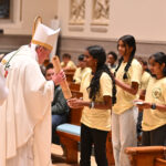 Morris Township conference reminds youth to be ‘Anchored in Hope’ #Catholic - Teenagers from around the Paterson Diocese in New Jersey gathered at St. Elizabeth University in the Convent Station neighborhood of Morris Township, N.J., for the annual Diocesan Youth Conference on Nov. 2. The theme of the event was “Anchored in Hope,” inspired by the Universal Church’s Year of Hope 2025.
Youth grades 8 to 12 attended the conference, which also included music, games, activities, and praise and worship featuring AOH (Array of Hope) Music and witness talks by Alanis Vega, AOH content coordinator, and Josh Rosa, one of the founders of Agnus Dei ministry, an author, and a Catholic speaker.

Click here to subscribe to our weekly newsletter.

The conference also hosted an exhibition of Eucharistic miracles with a first-class relic of St. Carlo Acutis, who was canonized as the first millennial saint by Pope Leo XIV in Rome on Sept. 7.
Bishop Kevin J. Sweeney celebrated a Mass for the conference participants, which was concelebrated with other priests.
The diocesan Office of Youth Ministry sponsored the conference, which Array of Hope produced.
BEACON PHOTOS | JOE GIGLI
 [See image gallery at beaconnj.org]  