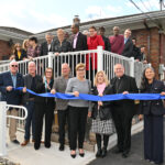 NJ’s longest-running group home opens doors at new location #Catholic - Christmas came early at Murray House in Clifton, N.J.
“Welcome home!” Joanna Miller, executive director of the Department for Persons with Disabilities (DPD) of Catholic Charities of the Paterson Diocese in N.J., and her staff exclaimed as they greeted clients of Murray House, a group home for men and women with intellectual and developmental disabilities.
Murray House staff and clients joined diocesan and community leaders, family members, and volunteers for the blessing and ribbon-cutting celebration of the group home’s new location on Nov. 14. DPD is part of Catholic Charities.
Opened in 1971, Murray House was the first group home for men and women with intellectual and developmental disabilities in the Garden State. The home is named in honor of Jimmie Murray, who had a developmental disability and died in 1969. DPD aims to make the move to the new location by Christmas.

Click here to subscribe to our weekly newsletter.

Residents were excited to tour the home and see their bedrooms freshly painted in the colors they selected. Laura Beahm said her sister, a resident of Murray House for 14 years, is looking forward to moving in.
“My sister called me every day about it. The house is beautiful. I love the garden, the ramp. It makes you feel so safe,” Beahm said.
Bishop Kevin J. Sweeney led the blessing and prayer.
“We thank God for the gift of life and the gift of family. And the family needs a home. And we’re so grateful to all those who have made this moment possible. We pray that every family would know peace and happiness in a safe home,” Bishop Sweeney said.
During the ribbon-cutting, Miller presented a plaque to the Murray family for its dedication, in partnership with DPD, for more than 50 years in making the home “a beacon of compassion and dignity.”
Jimmie’s brothers, Dennis Murray, vice president of the board of Catholic Charities, and Patrick Murray, officer in charge of the Paterson Police Department, and other family members, celebrated the milestone with residents and the community. The late Father Jack Wehrlen, founder of DPD, and the Murray family opened the first Murray House in 1971.
Bishop Sweeney thanked community and government leaders for their support, including U.S. Rep. Nellie Pou and State Sen. Kristin Corrado, both of whom attended the event.
“This is a sign of hope in this Jubilee Year of Hope for the Church. Look what we can do when we work together as neighbors and as a community,” Bishop Sweeney said.
The lawmakers applauded the Murray family and the DPD staff for their commitment to helping the residents flourish and grow. They wished the residents much happiness in their home.
“All of you will become one family. That is what we all want,” Pou said.
Corrado noted that there was a time when homes like Murray House were not available for “our most special and wonderful residents with intellectual and developmental disabilities.” It takes a village, said Corrado, adding, “Every person in this room is part of that village.”
Scott Milliken, CEO of Catholic Charities, said it has been their dream to relocate Murray House so that the residents can age in place.
“It’s a testament to our belief that every person deserves to age with dignity, independence, safety, and comfort. This fully accessible ranch-style home in Clifton will ensure they can continue to thrive safely in the place they love. Murray House has set the standard for compassionate, person-centered care for over five decades. This relocation honors that legacy while securing their future,” Milliken said. “This is your home, and you can stay here for a very long time. Enjoy it, live well, and prosper.”
Celebrating its 60th anniversary, DPD operates 10 group homes and one supervised apartment program, with a new group home scheduled to open in Morris County in 2026, to help individuals live with dignity and respect. DPD has been accredited by the Council on Accreditation since 1986 and is the only provider in the intellectual and developmental disabilities field in New Jersey to hold this accreditation.
Miller also said it was essential to the Catholic Charities staff to keep Murray House in Clifton because the residents have been part of the community’s fabric, and their day and support programs are nearby.
“They’re engaged in many activities. They worship there. They shop there. They take part in recreational activities and all the different activities that make Clifton a great place for them,” Miller said.
BEACON PHOTOS | JOE GIGLI
 [See image gallery at beaconnj.org]
