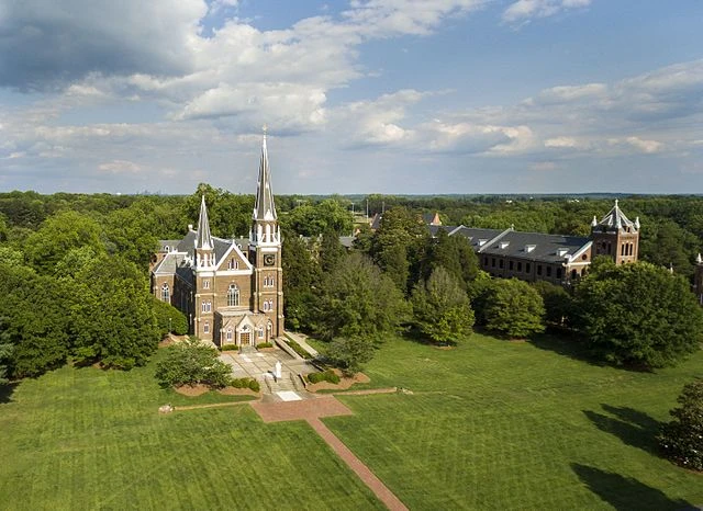 Retired Army general, Notre Dame professor to serve as president of Belmont Abbey College – #Catholic – 
 
 Mary Help of Christians Basilica on the campus of Belmont Abbey College. / Credit: Rnrivas, CC BY-SA 4.0, via Wikimedia Commons

Washington, D.C. Newsroom, Nov 20, 2025 / 16:30 pm (CNA).
Here’s a roundup of the latest Catholic education news in the United States:Retired Army general, Notre Dame professor to serve as president of Belmont Abbey CollegeBelmont Abbey College in North Carolina announced that Jeffrey Talley, a retired three-star lieutenant general in the U.S. Army and former tenured professor at the University of Notre Dame, will serve as its new president.In a Nov. 18 press release announcing the appointment, Talley said the school has a “unique opportunity” to “help young men and women get a rigorous academic experience in a faith-filled environment that’s strong in its Catholic identity so they can go forth in a world that’s become so challenging, so complex, so difficult.”Talley will assume the position of the college’s 21st president on Jan. 2, 2026. The chair of Belmont Abbey College’s board of trustees, Charles Cornelio, said in the release that the appointment comes after a seven-month search. Talley “is a person of deep Catholic faith who understands the mission of the college and will live it,” Cornelio said, highlighting the general’s decades-long history as a Benedictine oblate. “Leaders who are balanced both morally and professionally are in greater need than ever before. For this purpose, Belmont Abbey College exists,” Talley said. “I thank God for the opportunity to become part of the Belmont Abbey College family, where together we can bear the light of Christ in the world today.”Notre Dame professor attempts to distribute contraceptives, Plan B on campusA professor of gender studies at the University of Notre Dame attempted to use university space to facilitate the distribution of contraceptives and Plan B, according to a Nov. 19 report published by the student-run paper the Irish Rover.Pamela Butler, who is the director of undergraduate studies for the school’s gender studies department, has reportedly been reserving rooms in violation of university code for the group “Irish 4 Reproductive Health,” according to the Rover.School guidelines grant the use of university buildings and grounds for “recognized student groups.” The “reproductive health” group — which stated in the report it was “not affiliated with the university in any official capacity” — has been distributing free “resource bags” with condoms, Plan B, and information on abortion services for students in the university’s DeBartolo Hall.The group also openly advertises the distribution of contraception on Instagram as well as “workshops” hosted on campus on “exploring the principles of pro-choice Catholicism, how Catholic teaching supports reproductive justice, and how these ideas inform advocacy.”Minnesota Catholic institutions, including schools and universities, hit by pension deficitThe pension fund covering multiple Catholic schools and universities across Minnesota has been hit by an 0 million deficit, threatening retirement resources for thousands of current and former workers.The pension manager, Christian Brothers Services, is asking employers to make increased contributions to compensate for the massive shortfall, according to a report in the Minnesota Star Tribune, which cited “a big loss in a hedge fund that cratered a few years ago” in 2020 as reason for the deficit.Christian Brothers Services is a nonprofit organization that operates a church pension plan, one that is not bound by federal pension regulations, meaning pensioners are not eligible for federal payouts if their plans fail, according to the IRS.The Chicago-based organization manages the pensions of over 40 schools across the Dioceses of New Ulm, Crookston, and St. Cloud, as well as lay workers, and workers at St. Mary’s University in Winona and Minneapolis.Two schools have since pulled from the plan, according to the local report, while two others are planning to do so.