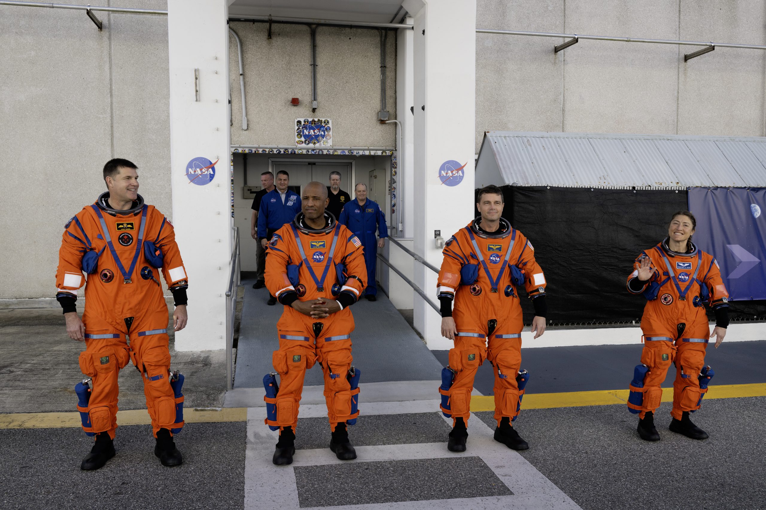 Artemis II Crew Launch Day Rehearsal – From left to right, CSA (Canadian Space Agency) astronaut Jeremy Hansen and NASA astronauts Christina Koch, Victor Glover, and Reid Wiseman are seen as they depart the Neil A. Armstrong Operations and Checkout Building to board their Orion spacecraft atop NASA’s Space Launch System rocket inside the Vehicle Assembly Building as part of the Artemis II countdown demonstration test, Saturday, Dec. 20, 2025, at NASA’s Kennedy Space Center in Florida.