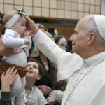 Curia must reflect ‘new humanity,’ founded on love, solidarity, pope says #Catholic – VATICAN CITY (CNS) — The cardinals, bishops, priests, religious and laypeople who work in the Roman Curia are called to be a “sign of a new humanity,” founded on mutual love and solidarity, not selfishness and individualism, Pope Leo XIV said.
“We are not mere gardeners tending our own plot, but disciples and witnesses of the Kingdom of God, called in Christ to be leaven of universal fraternity among different peoples, religions and cultures,” he told cardinals and top Curia officials Dec. 22 during a traditional pre-Christmas meeting with them.
“This happens if we ourselves live as brothers and sisters and allow the light of communion to shine in the world,” the pope said. “Let us remember this also in our curial service: the work of each is important for the whole, and the witness of a Christian life, expressed in communion, is the first and greatest service we can offer.”
The traditional Christmas greeting took place in the Vatican’s Hall of Blessing, which was decorated with red poinsettias and Christmas trees adorned with sparkling lights and silver and gold ornaments.
While previous popes used the pre-Christmas meeting to review the past year, Pope Leo continued Pope Francis’ practice of using it as an opportunity to reflect on what can help or hinder the Curia’s mission of sharing the Gospel. Cardinal Giovanni Battista Re, dean of the College of Cardinals, offered a brief summary of the past eight months of Pope Leo’s ministry in his opening remarks.

Click here to subscribe to our weekly newsletter.

Speaking in Italian, Pope Leo said he wanted to take a moment to remember Pope Francis, who passed away April 21 after 12 years as head of the universal church.
“His prophetic voice, pastoral style and rich magisterium have marked the church’s journey in recent years, encouraging us above all to place God’s mercy at the center, to give renewed impetus to evangelization, and to be a joyful church, welcoming to all and attentive to the poorest,” the U.S.-born pope said.
Pope Leo then focused his talk on two fundamental themes of Pope Francis’ 2013 apostolic exhortation “Evangelii Gaudium” (“The Joy of the Gospel”): mission and communion.
He told the Curia officials that the church’s very nature is to be “outward-looking, turned toward the world, missionary,” in order to bring the good news of God’s love to all people.
“The church exists to invite and gather all people to the festive banquet that the Lord prepares for us,” he said, so “every person can discover their identity as a beloved child, a brother or sister to their neighbor, and a new creation in Christ.”
“Transformed by this discovery, they become witnesses to truth, justice and peace,” he said.
For that reason, he said, “we need an ever more missionary Roman Curia, in which institutions, offices and tasks are conceived in light of today’s major ecclesial, pastoral and social challenges, and not merely to ensure ordinary administration,” to better serve local churches and their pastors.
When it comes to communion, he said, Christmas is an important reminder that “Jesus came to reveal the true face of God as Father, so that we might all become his children and therefore brothers and sisters to one another.”
God’s love, revealed by Jesus, enables all members of the Catholic Church “to be a sign of a new humanity — no longer founded on selfishness and individualism, but on mutual love and solidarity,” Pope Leo said.
The task of fostering greater communion both within the church and in the world “is urgent,” he said.
Communion in the church is always a challenge, he said, because of “forces of division” that may sometimes be at play. “We can fall into the temptation of swinging between two opposite extremes: uniformity that fails to value differences, or the exacerbation of differences and viewpoints instead of seeking communion.”
“Thus, in interpersonal relationships, in internal office dynamics, or in addressing questions of faith, liturgy, morality and more besides, there is a risk of falling into rigidity or ideology, with their consequent conflicts,” Pope Leo said.
Members of the church are called to “conversion,” and to remember, “though many and diverse,” they are members of the one body of Christ as “brothers and sisters in him,” he said.
“This communion is built not so much through words and documents as through concrete gestures and attitudes that ought to appear in our daily lives, including in our work,” he said.
Pope Leo warned against “bitterness” that may build up in those who, after many years of service in the Curia, “observe with disappointment that certain dynamics — linked to the exercise of power, the desire to prevail, or the pursuit of personal interests — are slow to change.”
He encouraged officials to seek “genuine fraternal friendship” and to pray for personal conversion and the “grace to find trustworthy friends, where masks fall away, no one is used or sidelined, genuine support is offered, and each person’s worth and competence are respected, preventing resentment and dissatisfaction.”
When members of the Curia and the wider church live this way, he said, it also becomes a sign to “a world wounded by discord, violence and conflict, where we also witness a growth in aggression and anger, often exploited by both the digital sphere and politics.”
“The Lord’s birth brings the gift of peace and invites us to become its prophetic sign in a human and cultural context that is too fragmented,” he said.
After meeting with the Curia leaders, the pope went to the Vatican audience hall where he greeted hundreds of employees of the Vatican and the Diocese of Rome and their families. He spent almost 30 minutes walking along the barriers, greeting and speaking with those in attendance, and blessing babies and children.
In his speech, he encouraged employees and their families to learn from Jesus “the style of simplicity and humility, and let us all work together to ensure that this is increasingly the style of the church in all its expressions.”
“Sometimes we are so caught up in our activities that we do not think about the Lord or the church,” he said. “But the very fact of working with dedication, trying to do our best, and also — for you lay people — with love for your family, for your children, gives glory to the Lord.”