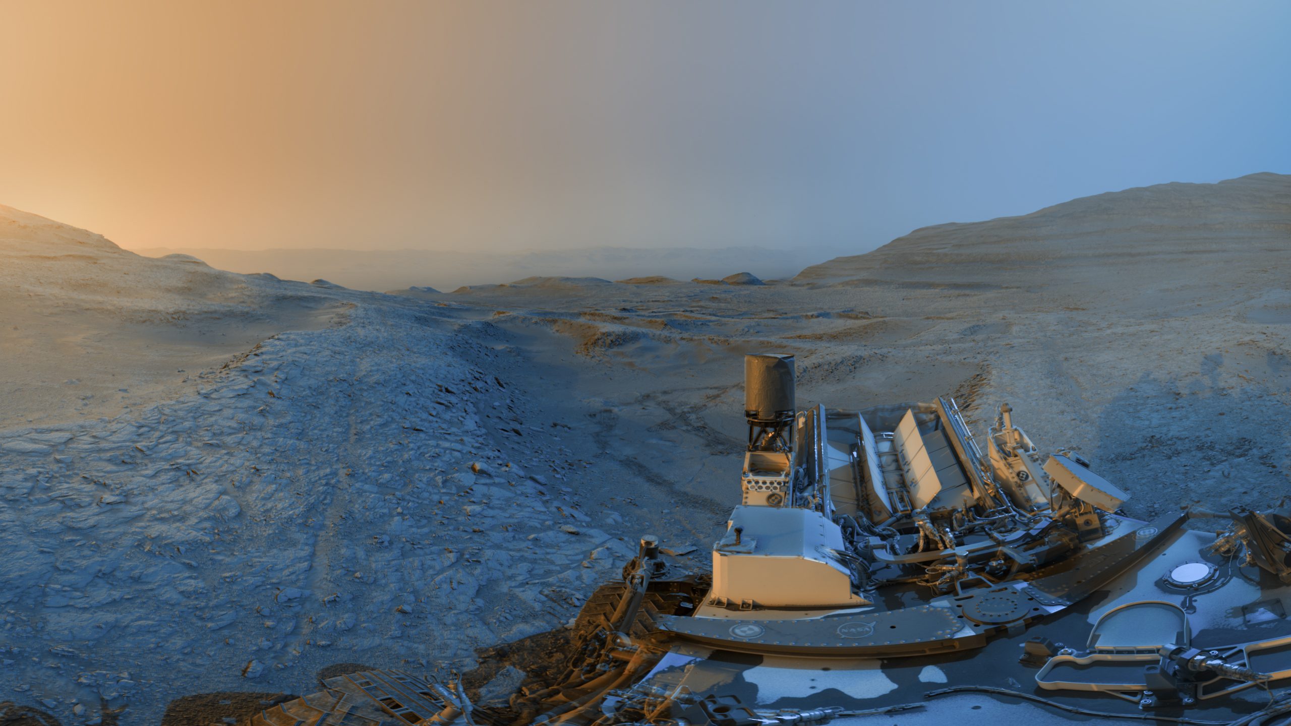 Curiosity Sends Holiday Postcard from Mars – NASA’s Curiosity Mars rover used its black-and-white navigation cameras to capture panoramas at two times of day on Nov. 18, 2025, spanning periods that occurred on both the 4,722nd and 4,723rd Martian days, or sols, of the mission. The panoramas were captured at 4:15 p.m. on Sol 4,722 and 8:20 a.m. on Sol 4,723 (both at local Mars time), then merged together. Color was later added for an artistic interpretation of the scene with blue representing the morning panorama and yellow representing the afternoon one.