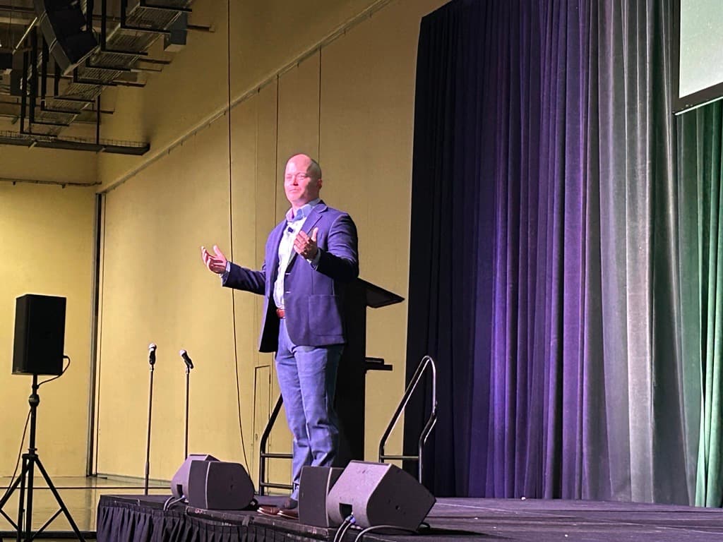 ‘As men, you’re called to act!’ speaker says to a packed room of young men at SEEK 2026 #Catholic 
 
 John Bishop, founder of Forge, speaks to hundreds of young men at the SEEK 2026 conference in the Diocese of Fort Worth, Texas, on Jan. 2, 2026. | Credit: Amira Abuzeid/CNA

Jan 6, 2026 / 07:00 am (CNA).
Hundreds of young men at the SEEK 2026 conference in the Fort Worth, Texas, Diocese this weekend filled a cavernous room to learn about what it means to be a man formed by “Jesus Christ and his Church.”John Bishop, founder and executive director of Forge, an organization that supports the family with an emphasis on masculinity, told the young men that “you are much more than your animalistic desires. Live something higher for someone higher.”In his talk titled “God Made Men,” Bishop spoke about how when Adam, the first man, “opened his eyes, he had never seen a woman before. She was completely naked.”“It was a great day for Adam,” Bishop said to waves of laughter. “Adam was the Elon Musk of the garden.”Taking a more serious tone, Bishop asked: “How would Adam see Eve? In his theology of the body, Pope John Paul II said Eve’s body was a manifestation of her soul. Eve had a perfect body, but when Adam saw her naked body, he didn’t lust over her.”“He realized who she was and who he was: made to make a gift of himself to her,” he said.Bishop then turned to what happened next: “What did Adam do as the snake came into the garden?” he asked.“Nothing! The most common, toxic, nauseating sin that runs rampant throughout men in the world is that we don’t do a damn thing.”“When we see our brothers walking into sin, we twiddle our thumbs. When we see our daughters walking out wearing next to nothing, we say nothing. When we’re grandfathers seeing the culture going in a bad way, we watch football,” he said.‘The image of God lives in a man fully alive’“You’re called to act!” Bishop admonished the group. “You might be filled with doubt … but it might be time for you to take the first step.”“The image of God lives in a man fully alive … Study after study shows that when a good man acts and doesn’t hold anything back, when he follows Christ with all [he is], … when he gives himself over [to Christ], the effect of that one man’s life multiplies beyond anything that we can understand,” he said.Hundreds of young men listen to John Bishop’s talk on masculinity on Jan. 2, 2026, at the SEEK conference in Grapevine, Texas. | Credit: Amira Abuzeid/CNAPatricio Parra, a sophomore at Texas A&M University, told CNA that he enjoyed Bishop’s talk because he and his friends have noticed how “society says it’s toxic to be masculine.”Parra said a New York Times journalist asked him and his friends after the talk why his generation of men was so invested in the faith.“There’s a striving for men to want to be men again,” he told her. “As a society, we see male role models on YouTube, but they are deformed. Recently, there aren’t a lot of good masculine models to follow.”Parra said what stood out to him the most after Bishop’s talk was the idea that Adam saw Eve’s physical beauty as the same as her internal beauty and recognized her dignity.“We have to strive to be as masculine as that,” Parra said.He said he took to heart three pieces of advice Bishop gave the men in the audience.First: “There’s no glory without the cross, no sainthood without suffering; so suffer a little bit. Make your body go through hard things,” Parra recalled. “Everything we suffer now will bring fruit for others, including our children someday, who will want to emulate us.”Next, Parra said Bishop advised that young men invest in solid, masculine friendships where they encourage one another toward sainthood.Last, Bishop told his listeners to be like St. Joseph, who, after Adam, was “one of the most manly men in Scripture.”“Joseph never said a word. We just know what he did,” Parra said. “We should do the same: just be quiet and act.”Parra demonstrated a hand motion he and his other friends from Texas A&M invented to go with the words “Zip it and act!” He made a zipper motion across his mouth and then the letter “A” with his fingers.“Don’t just talk about asking a girl out; do it!” he said enthusiastically. “Don’t just think about seminary; go do it!”