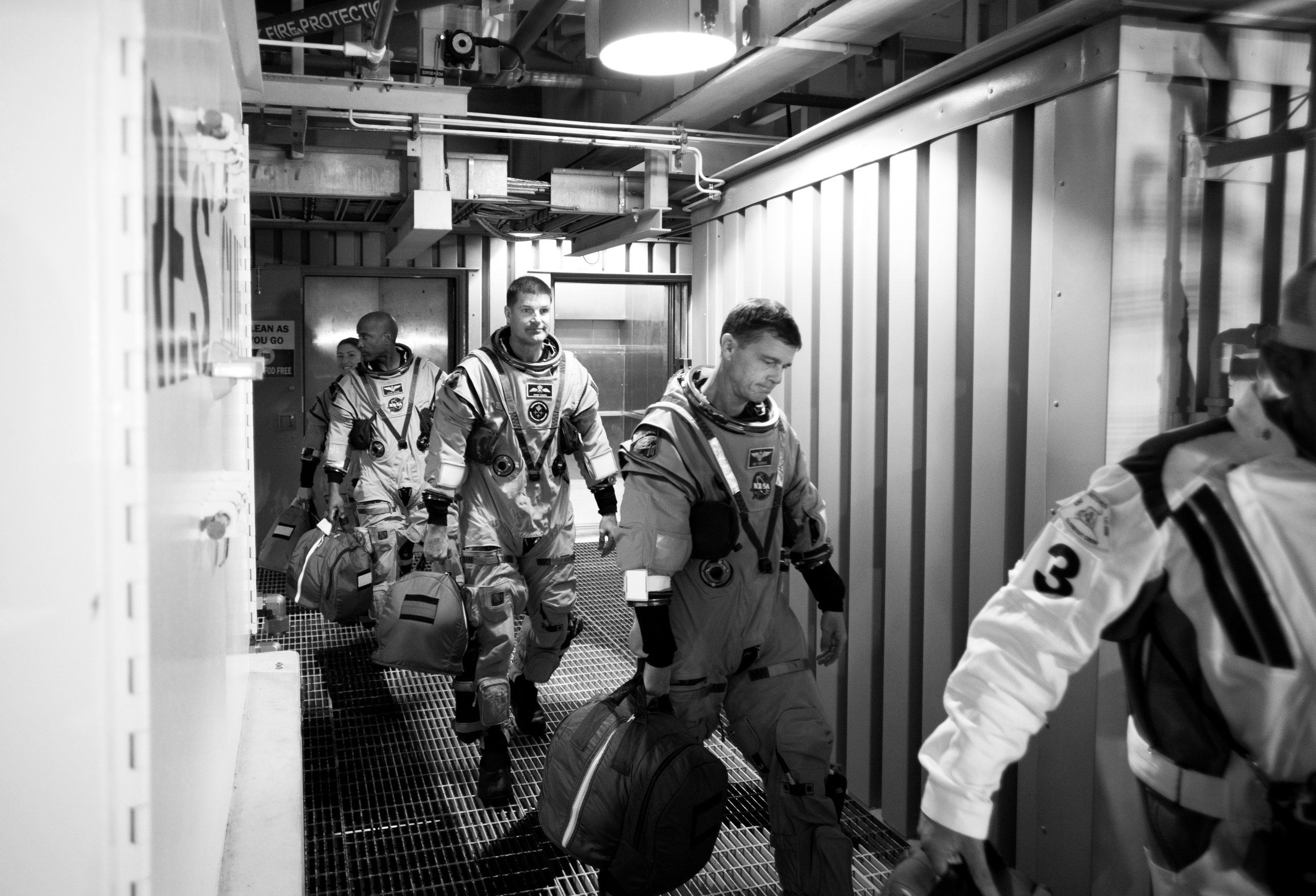 Best of 2025: Artemis II Countdown Demonstration Test – Artemis II crewmembers (left to right) NASA astronauts Christina Koch, mission specialist; and Victor Glover, pilot; CSA (Canadian Space Agency) astronaut Jeremy Hansen, mission specialist; and NASA astronaut Reid Wiseman, commander are led to the crew access arm as they prepare to board their Orion spacecraft atop NASA’s Space Launch System rocket during the Artemis II countdown demonstration test on Dec. 20, 2025.