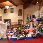 Dominican pride fills Paterson church for colorful Altagracia celebration #Catholic - On Jan. 21, Bishop Kevin J. Sweeney presided over Mass at St. Stephen Parish in Paterson, N.J., celebrating the Feast of Our Lady of Altagracia — a major expression of Dominican faith and identity, as she is considered the protective mother of the Dominican people.

Click here to subscribe to our weekly newsletter.

St. Stephen’s pastor, Father Rafael Ciro, concelebrated. During the Mass, the bishop blessed an image of Our Lady of Altagracia, which was displayed alongside the Dominican flag, candles, and flowers on the altar. To honor their heritage and devotion, many churchgoers wore colorful traditional clothing.
On Jan. 21, 1691, the Spanish army, led by Antonio Miniel, defeated the French army during the Battle of the Sabana Real in the eastern part of the island of Santo Domingo. This historical victory is linked to the belief that the Spanish asked for the intercession of Our Lady of Altagracia, thereby embedding her role as a symbol of hope and protection for Dominicans, a role the community commemorates each year.
BEACON PHOTOS | JOE GIGLI
 [See image gallery at beaconnj.org] &nbsp;