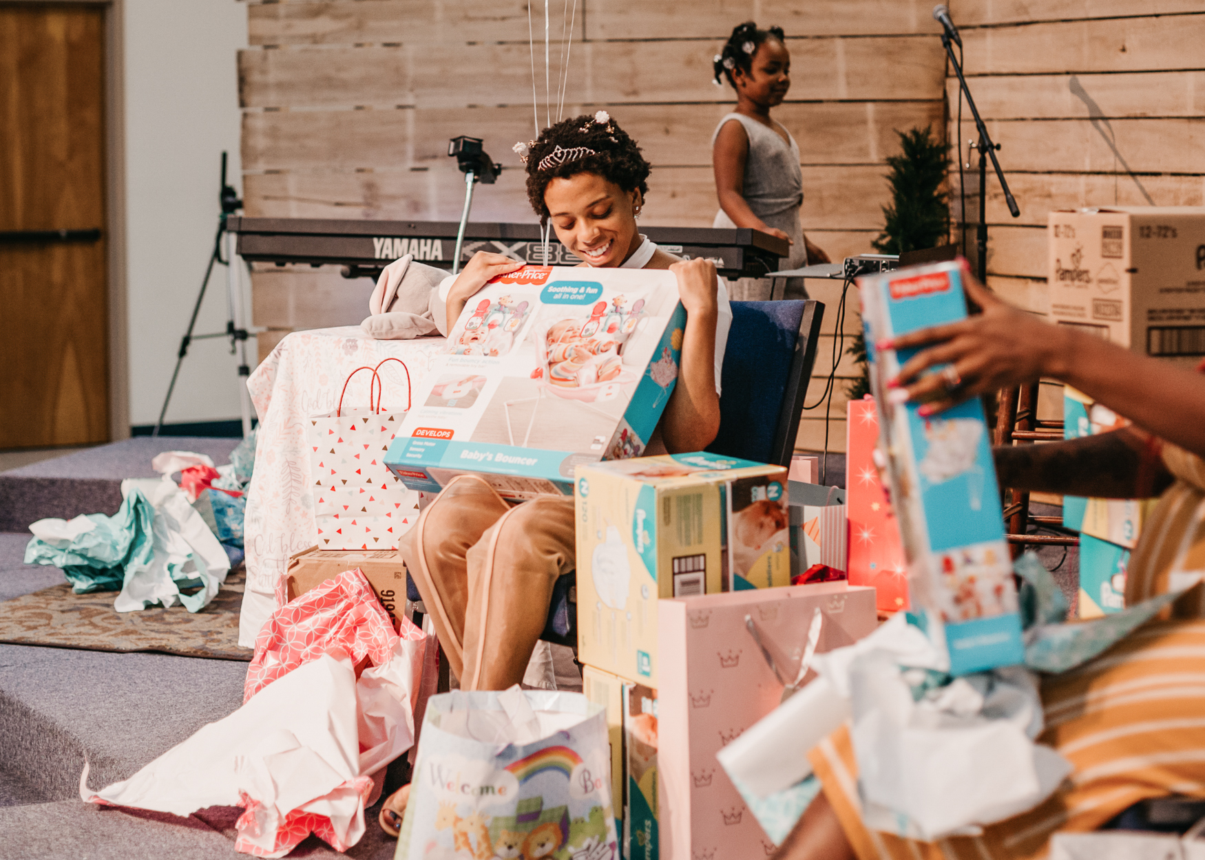 How one woman’s unexpected pregnancy launched a pro-life group helping women in need #Catholic 
 
 A woman receives a baby shower at her local church through Embrace Grace. | Credit: Embrace Grace

Jan 18, 2026 / 06:00 am (CNA).
Amy Ford was 19 years old when she found herself with an unplanned pregnancy. Scared and thinking her life and dreams were over, she attempted to get an abortion but was unable to go through with it. Ford and the baby’s father turned to their church for support and received none. The experience led her to create Embrace Grace, a nonprofit that provides support and community through local churches for pregnant mothers in need.The story behind the ministryFord told EWTN News that she thought “my life was over, my dreams were over, that my parents were going to hate me.” She said she thought she would end up homeless. “The father of the baby felt the same way and we just thought we could have an abortion and maybe that’s a quick fix and we’ll just deal with the consequences of a broken heart later. And even though we grew up knowing abortion was wrong, we just kind of went into this mode of trying not to feel anything,” Ford recalled.So, she went to an abortion clinic. As the nurses explained what they were going to do during the procedure, Ford began to hyperventilate and passed out. She was told she was “too emotionally distraught” to make a decision and that she could go back to the abortion clinic another day.As she walked into the waiting room, she told the baby’s father that she was still pregnant. At that moment, the two decided they would keep the child. The high school sweethearts knew they wanted to get married one day; they just didn’t expect to have a child before marriage.The two went to an evangelical pastor whom they knew personally to ask him if he could marry them.“He said, ‘No, I’m sorry, because you sinned I will not bless this marriage,’” Ford shared.The couple found another pastor to marry them and got married when Ford was 16 weeks pregnant. They tried going back to their church after that but it was “the elephant in the room” — others changed how they interacted with them and they decided to stop attending church for a period of time.Ford and her husband welcomed their son — who is now 27 years old and also works in the pro-life movement — and have been married for 27 years, welcoming three more children after their firstborn.Amy Ford, founder of Embrace Grace. | Credit: Embrace GraceHelping womenLooking back at her experience, Ford felt called to help women who found themselves in these situations, not sure where to go, and weren’t aware of the resources available to them. So she started a small group at her church for women who were experiencing an unexpected pregnancy.Ford admitted that back then she didn’t know what a pregnancy center was or what the pro-life movement was.“If someone would have said, ‘I work in the pro-life movement,’ I would have assumed that meant picketing because that’s the only thing the media shows,” she admitted. “I didn’t know what a pregnancy center was even when I started Embrace Grace, the group. I didn’t know anything about it. So, I never thought, ‘I’m starting a pro-life group.’ That wasn’t even on my mind. I just wanted to start a small group for women that have unexpected pregnancies.”In 2008 Ford hosted her first group, which was made up of three women who met at a local church in the Dallas-Forth Worth area. After meeting for 12 weeks as a group, “they didn’t even seem like the same person by the end of it,” Ford recalled.“They had completely transformed. They were empowered as women to be the moms that God created them to be.”After the first group, Ford held another Embrace Grace session, and another and another. With each passing session, more and more young women were attending and slowly more and more churches were getting involved.Today, Embrace Grace is in over 1,200 churches across the country — mostly in evangelical, Baptist, and Catholic churches. A woman who joins an Embrace Grace group goes through a 12-week curriculum that aims to help her experience healing and remind her of who God made her to be as a daughter of God and a mother. Additionally, the church hosting the group throws each woman a baby shower.A woman receives a baby shower at her local church through Embrace Grace. | Credit: Embrace GraceEmbrace Grace also has two other programs: Embrace Life and Embrace Legacy. Embrace Life is a 20-week program that teaches the women more practical skills in terms of parenting, the newborn phase and postpartum, how to manage finances, and more. Embrace Legacy is a 12-week program aimed at new or single fathers.Ford hopes that Embrace Grace serves as a tool of “courage and the bridge to get them actually going to church and raising their kids in the church and being a part of a spiritual family.”The nondenominational nonprofit also works in partnership with local pregnancy centers that are within a 30-mile radius of a church that hosts an Embrace Grace group by giving them what they call “Love Boxes” to give women who find out they are pregnant and are seeking support. The Love Box contains a onesie with the words “Best Gift Ever,” a book called “A Bump in Life” — which contains 20 testimonies from women who chose life — a journal, a handwritten letter encouraging a new mother, and an invitation to join the local Embrace Grace group.Love Boxes are given to women at pregnancy centers after they find out they’re pregnant and are in search of support. | Credit: Embrace Grace“Because most pregnancy centers have sonogram machines, that means they’re medical, which means they have HIPAA laws that they have to abide by. So, they can’t just give the church the girl’s name,” Ford explained. “So these Love Boxes are kind of a way, another touch, for the mom to find out more … and that there’s a church that wants to walk alongside you.”Embrace Grace recently reached a milestone by giving out 150,000 Love Boxes since its launch in 2018.Looking ahead, Ford’s goal is to be in 23,400 churches. If that number sounds specific, that’s because it is. By using different tools, Ford and her team concluded that if they want every woman who finds herself in an unplanned pregnancy to be able to turn to a church for support, Embrace Grace needs to be in “23,400 churches strategically placed around the United States … so that no mom would ever have to walk alone.”“We are just putting it out there, trying to partner with as many churches as possible, so that we can make that happen,” she said. “That is our big dream. That that’s what the world would look like — that no mom would have to walk alone and that she would have a church to turn to in her local area.”“I believe in leading Embrace Grace, we have front-row seats to miracles.”