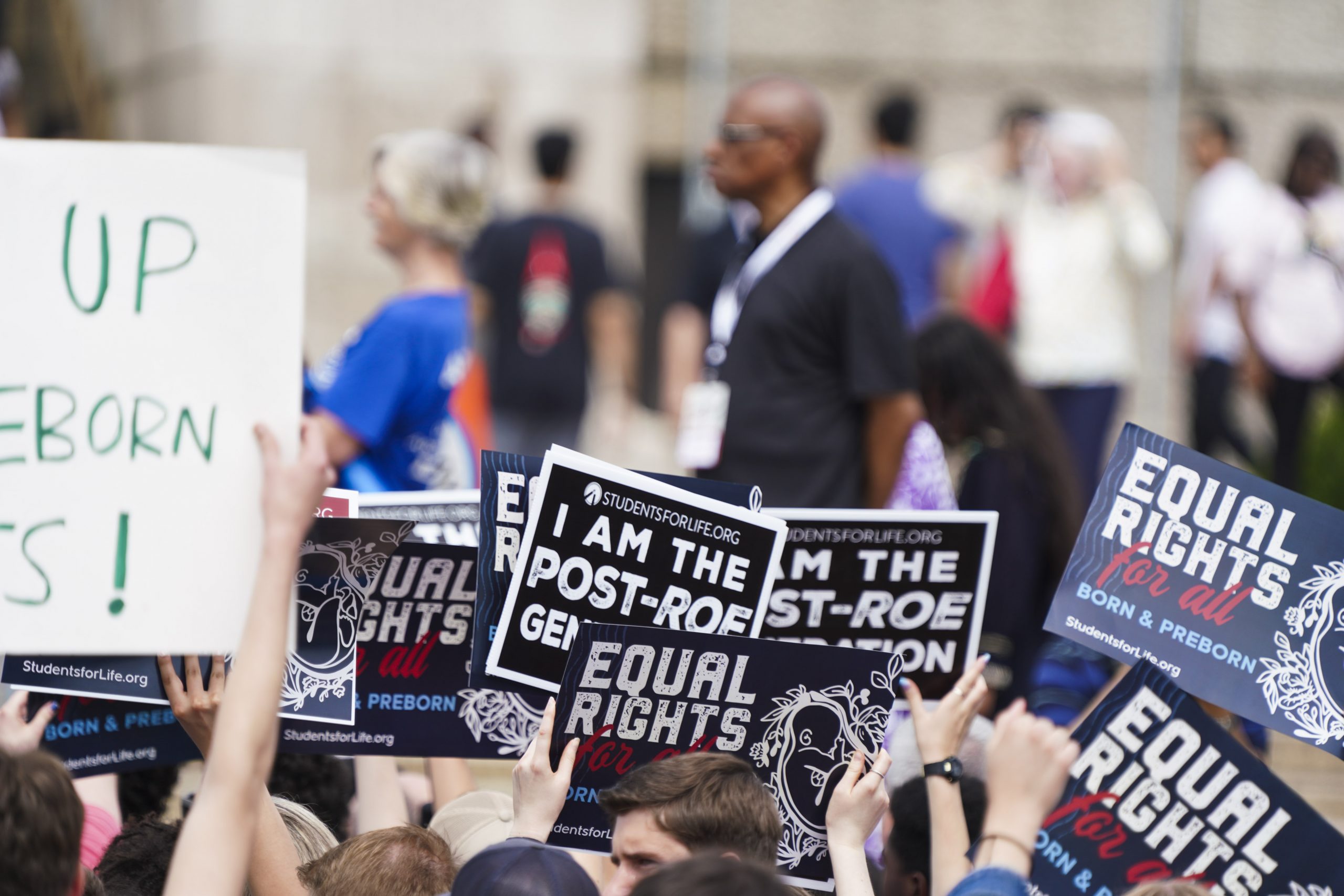 Pro-life movement has mixed reaction after Trump’s first year of second term #Catholic 
 
 Participants in a pro-life rally hold signs in front of the Lincoln Memorial in Washington, D.C., on June 24, 2023, at a rally marking the first anniversary of the Supreme Court's Dobbs decision that overturned Roe v. Wade. | Credit: Joseph Portolano/EWTN News

Jan 20, 2026 / 14:37 pm (CNA).
Members of the pro-life movement have mixed thoughts on the first year of President Donald Trump’s second term, noting many wins early into his presidency but a number of shortfalls as time has gone by.Some wins include defunding Planned Parenthood, walking back some of President Joe Biden’s initiatives, and removing foreign aid funding for organizations that promote abortion. However, a lack of action on chemical abortions and weakened rhetoric surrounding taxpayer-funded abortions are causing concern.A notable pro-life win was included in the tax overhaul bill signed by Trump in July, which cut off all Medicaid reimbursements for organizations that provide a large number of abortions, such as Planned Parenthood.Amid funding cuts, nearly 70 Planned Parenthood affiliates shut down. The administration also initially cut off Title X family planning grants from the abortion giant, but those have resumed.The president pardoned pro-life protesters convicted of violating the Freedom of Access to Clinic Entrances (FACE) Act and blocked foreign aid from supporting organizations that promote abortion. He rescinded several policies from the Biden administration, including one that paid Pentagon workers to travel for abortions. He also established strong conscience protections for pro-life doctors.“Right out the gate, we saw some progress on the pro-life issue,” Kelsey Pritchard, a spokesperson for Susan B. Anthony Pro-Life America (SBA), told EWTN.Yet, she cautioned: “We have also not seen progress in the one area that matters the most — and that’s on abortion drugs.”Health Secretary Robert F. Kennedy Jr. launched a study into the safety of the abortion pill mifepristone in September 2025, but so far no action has been taken to curtail the drug. Rather, the Food and Drug Administration (FDA) went in the opposite direction, approving a generic version of mifepristone later that same month.Pritchard said that move was “the opposite of what they should have done,” and referred to the generic mifepristone as “a new kill pill to increase the number of abortions that are done in this country.”She said Kennedy’s promised study has “absolutely been moving too slow” and added that there is no confirmation it even began or is taking place. SBA called for FDA Commissioner Marty Makary to be fired following allegations he was “slow-walking the report for political reasons,” she said.Trump has said abortion should be regulated by the states, but Pritchard warned “those [pro-life] laws can’t be in effect at all, really, when mail-order abortion happens with the abortion drugs.”“They’re allowing [California Gov.] Gavin Newsom and [New York Gov.] Kathy Hochul and their blue state friends to completely nullify the pro-life laws in states like Texas and Florida,” she said.Joseph Meaney, a senior ethicist at the National Catholic Bioethics Center, similarly said “the delay in the promised review of the rushed process in which mifepristone was approved as an abortion drug by the FDA has frustrated pro-lifers.”“When the FDA approved a second generic version of mifepristone, … it highlighted the lack of progress in fighting the leading means of doing abortions in the [United States],” he said.Trump also began to waver on taxpayer-funded abortions early in 2026, asking Republicans to be “flexible” on the Hyde Amendment amid negotiations on extending health care subsidies for the Affordable Care Act. Trump later unveiled “The Great Healthcare Plan” and said the White House intends to negotiate with Congress to ensure pro-life protections.Pritchard called taxpayer-funded abortion “a very basic red line” and said it’s “concerning to see Republicans back away from something so basic.”She warned Republicans to not take pro-life voters for granted in the upcoming midterms, saying “you’ll lose the elections and we won’t have the majority of Congress” without pro-life voters.“You must remain the pro-life party or you will lose the midterms if you decide to bow to the pro-death Democrat agenda,” Pritchard said.Meaney said there is “a widespread feeling that the second Trump administration has seemed to deprioritize issues important to the pro-life community,” adding he has “seen calls for pro-life groups to ‘flex their muscles’ and show that they cannot be taken for granted.”However, he said the shortfalls “should not obscure the fact that the Trump administration has rolled back the Biden-era pro-abortion measures internationally and domestically.”“It even achieved a temporary defunding of Planned Parenthood domestically in legislation,” he said. “The federal government no longer funds research on fetal tissues and defends the conscience rights of health care professionals and others robustly.”Trump also signed an executive order that directed departments and agencies to boost access to and reduce the cost of in vitro fertilization (IVF). The Catholic Church opposes IVF, which results in the destruction of human embryos, ending human lives.