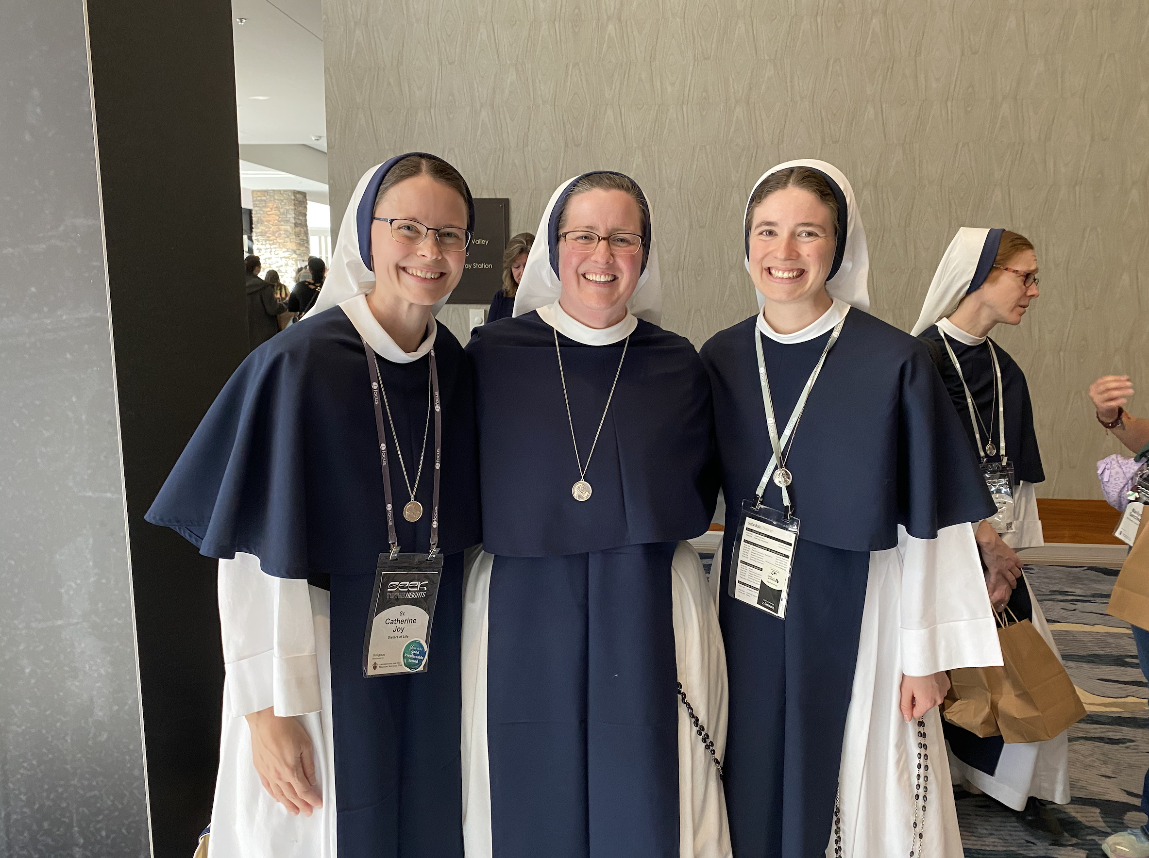 SEEK 2026: 7 ways to discern your vocation #Catholic 
 
 From left to right: Sister Catherine Joy, Sister Virginia Joy, and Sister Israel Rose of the Sisters of Life at SEEK 2026 in Denver. | Credit: Francesca Fenton/EWTN News

Jan 7, 2026 / 06:00 am (CNA).
Hundreds of young women filled a ballroom on Jan. 4 at the 2026 SEEK Conference in Denver to hear Sister Virginia Joy Cotter, SV, discuss how to follow God’s call and determine one’s vocation.“When we think about vocation, it’s ultimately a call to love and be loved,” Sister Virginia Joy said during her talk, titled “The Adventure of the Yes: Following God’s Call.”“Growing up, or even now, you’re probably asked, ‘What are you going to do when you grow up? What’s your major? What do you want to do with your life?’” she said. “I would guess no one has probably asked you, ‘What are you going to do with your love? How do you plan to make a gift of yourself?’ But these are the questions that sit behind a vocation.”“For some, the word vocation might be completely foreign to you. For others, maybe it provokes a stream of emotions from wonder to anticipation to anxiety. Whatever it means to you, it’s good to take stock of where it sits with you right now and open your heart to whatever God wants to give you this morning.”Sister Virginia Joy shared that “ultimately, our vocation is not a problem to be fixed or a riddle to be solved … Vocation is deeply relational, personal, and distinct. It comes from the Latin ‘vocare,’ meaning to call, to name, to summon. There’s one who calls and there’s one who responds. It’s a relationship between each individual and God.”Here are seven ways a person can discern his or her vocation based on Sister Virginia Joy’s talk:Pay attention to where and how you are called to loveSister Virginia Joy shared that the questions behind one’s vocation are fundamentally about “what are you going to do with your love” and how you are called to “make a gift of yourself,” not merely what career or role you will have.Receive God’s love firstShe emphasized that the prerequisite for hearing God’s call is first receiving his love, since vocation flows from a relationship.“When I think about a vocational call, I think of two things: First, God is the one who calls, and it is always a call of love. Second, we are the ones to respond to that call and to love in return. So first, the prerequisite to hearing God’s call is receiving his love,” Sister Virginia Joy said.Develop a real prayer life and speak honestly to GodGod makes himself known in prayer, especially when a person speaks from the heart — expressing longing, confusion, loneliness, or desire for meaning.Sister Virginia Joy highlighted that “God is looking for a place to break in and make himself known. I trust you’ve experienced it here at SEEK. It’s real. He’s real. And he is in pursuit of your heart. He knows you and he desires that you come to know him. This happens in prayer.”“But prayer can be challenging because we’re used to instant gratification. We want to see results. And yet relationships, they’re not about results,” she added. “Relationships take time, patience, and trust. Sometimes I think we settle or we allow ourselves to get distracted because real love means facing our weakness and searching for the Lord in times of loneliness, doubt, and even pain.”Sister Virginia Joy Cotter, SV, during her talk on Jan. 4, 2026, at the SEEK conference in Denver. | Credit: Francesca Fenton/EWTN NewsStay close to the sacraments, especially confession and the EucharistSister Virginia Joy emphasized that living in grace and regularly receiving the sacraments helps ensure that a person does not miss God’s call and gains the strength to respond in his time. She shared with those gathered that she has always found herself making life decisions after “a good confession — decisions to move across the country, decisions to become a missionary, decisions to accept a particular job or begin or end a dating relationship.”“I know there can be a lot of fear about somehow missing what God is calling me to,” Sister Virginia Joy said. “And I just want to crush that fear because the truth is if you’re staying close to the sacraments, if you’re living in grace, you will not miss what God is calling you to. And because of the grace of the sacraments, you will have the strength to respond in God’s time.”Live your call to love daily, even before knowing your definitive vocationSister Virginia Joy stressed that holiness and vocation are lived now, through everyday acts of love, even before one enters marriage, religious life, or another permanent state.She asked those gathered: “Where are we called to love?”“It’s not a complicated question. All the love happens right where God has you — with family, friends, roommates. We are each given so many opportunities to love every day. You might not be in your definitive vocation right now or five years from now, but your call to love is now. Your call to make a gift of yourself is now,” she said.Recognize your unique giftsEspecially for women, discerning vocation involves recognizing the “uniquely feminine” capacity for receptivity, generosity, spiritual maternity, and leading others to God, Sister Virginia Joy explained.“As women, we possess a unique capacity for love … Written into our very makeup by design, we as women have space for another, room for another. And the physical capacity — we’ve heard this over the days — the physical capacity to receive and carry life sheds a much deeper reality within the heart of each woman,” she said. “Our bodies and souls are intimately connected and together they tell us something — that our love is receptive, sensitive, generous, maternal.”Observe where your heart becomes undivided and freeA key sign of vocation is interior freedom and unity of heart, where fear gives way to peace and clarity about where, as Sister Virginia Joy said, one is called “to make a gift of oneself in a total way.”She shared that while discerning her own vocation her heart was divided — seeing the beauty in both married life and religious life. It wasn’t until she asked in prayer, “What do you want, Lord?” while on retreat with the Sisters of Life that she heard him say, “You. You. All of you for myself.”“And in an instant, my heart was undivided,” she recalled. “I knew where I was being called to give my love and my life, and I felt more free than I ever had.”“Your love story is going to be perfectly unique to you,” Sister Virginia Joy added. “God has been preparing something far beyond your expectations and he desires your freedom to respond with an undivided heart. Whether it be marriage, religious life, lay life, there is no doubt he wants you and your unique love. God loves you.”