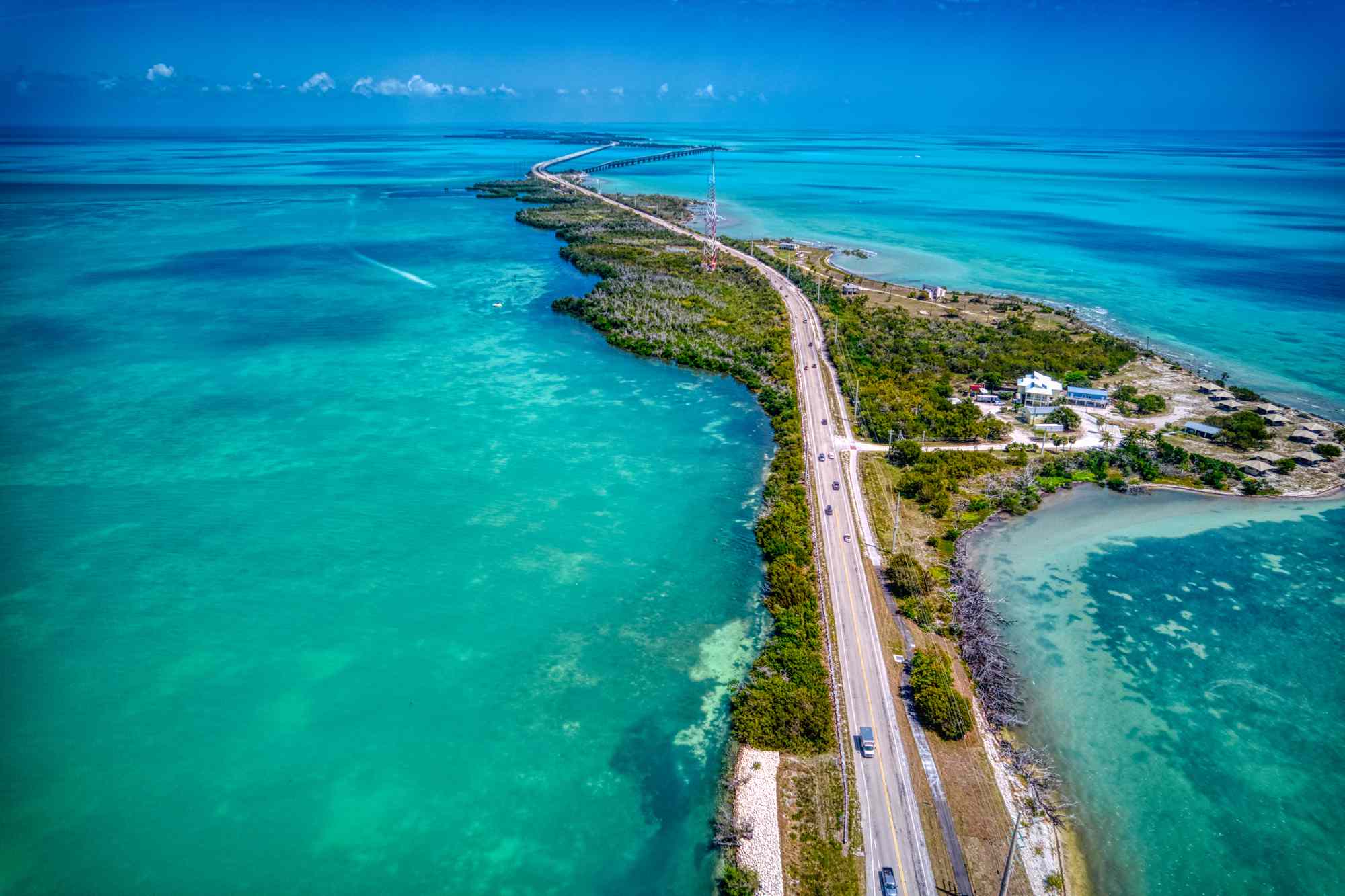 This 113-mile Highway Through the Florida Keys Is Lined With Delicious Seafood, Charming Islands, and Ocean Views #Travel Driving the Overseas Highway from Key Largo to Key West, I let reef dives, seafood shacks, and impossibly blue water set the pace.