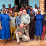 Two Assumption charities deliver love, hope to impoverished Africans #Catholic - Dennis, a 30-year-old who lives in a village of the impoverished African nation of Sierra Leone, had been suffering from excruciating leg pain for the past few years. Cellulitis, a bacterial infection, had caused a burning red sore up the entire side of his left leg.
Thanks to Africa Surgery, a non-profit based at Assumption Parish in Morristown, N.J., Dennis received surgery that relieved his pain. Surgeons in Sierra Leone took skin from the thigh of his right leg and grafted it to the infected left leg. Dennis has since returned to his daily activities, including work.
Last month, Assumption helped ensure that two non-profit outreaches started at the parish — Africa Surgery and the Village Angels of Tanzania — continue transforming the lives of poor people in Africa. The parish held its 15th Annual Christmas Market, which raised a record $27,792 to support urgent medical care, food, and education in Sierra Leone and Tanzania.
In addition, men from Assumption filled two large shipping containers late last year with items such as crutches and hand-powered mobility carts. The first container arrived in Sierra Leone on Jan. 14. Tom Johnson, founder of Africa Surgery and an Assumption parishioner, will distribute the items in Sierra Leone, where he is situated now.

Click here to subscribe to our weekly newsletter.

In 2007, Johnson founded African Surgery, which has helped thousands of Sierra Leonians with medical issues ranging from simple tooth extractions to complex spinal surgeries around Freetown and Makeni. For about six months a year, he lives in Sierra Leone, working with international and local medical programs and facilities that provide diagnoses and treatment on a wide range of medical issues. For the rest of the year, Johnson coordinates activities from Morristown, NJ, with help from some in-country assistants.
“It’s hard for people in Sierra Leone. They are desperately poor and work but don’t have enough food,” said Johnson, a home repairs contractor. “I’m overwhelmed by the number of people in great need. We don’t have enough resources for everyone. But when we can help, it’s exhilarating,” he said.
Africa Surgery also supports some students in their education and provides some locals with part-time jobs and food.
“I’m grateful for Assumption’s support. Their donations mean a lot to the people of Sierra Leone,” Johnson said.
Founded in 2015, the Village Angels provides urgently needed food, clothing, and basic home furnishings to residents of several small villages in northwest Tanzania. They are mainly elderly people who have little to eat and live in remote huts. The program partners with the local Franciscan Sisters of St. Bernadette to provide jobs to local youths, who visit the isolated elderly people every week. Sergio Burani and his wife, Johanna, also parishioners of Assumption, established the outreach.
The Village Angels reaches people in the area, which welcomed 500,000 refugees of the Rwandan War of 1994. The U.N. built a huge tent city where some refugees stayed for 10 years, straining family dynamics, infrastructure, farmland, and other resources. The impoverished conditions forced middle-aged people to take their children and move to the cities, leaving the elderly to live alone with no pensions or family support. The youth bring them food, water, and firewood. Meanwhile, Sister Dativa Mukebita, the program’s director, and other sisters in her community provide moral support and minor medical attention.
In 2017, the Village Angels dedicated a new multipurpose building in honor of the late Msgr. Martin Rauscher, Assumption’s former pastor, who supported both non-profits. The youths in the program weave baskets, sew clothing and household items, harvest honey from their bee farm, and harvest bananas from their plantation to generate local revenue for the program. The Village Angels also purchase food items, clothing, and furnishings for the elderly.
“Our efforts give dignity to the young and the old. We’re saying, ‘We see you. You’re important.’ The Village Angels fills a void. The youth like visiting the elderly. The elderly like it when the youth call them ‘grandma’ or ‘grandpa.’ Everybody wins,” Johanna Burani said. “This is what the Lord wants us to do. We know these people and want to be their voice.”
Like his predecessor, Msgr. Rauscher, Msgr. John Hart, Assumption’s current pastor, is supportive of Africa Surgery and the Village Angels of Tanzania.
“Our generous parishioners support these two charities, founded by people we know and love. We have parishioners who work to help them in many ways. These charities are always in our prayers,” Msgr. Hart said.
Information: visit Africa Surgery and the Village Angels of Tanzania.
 [See image gallery at beaconnj.org]