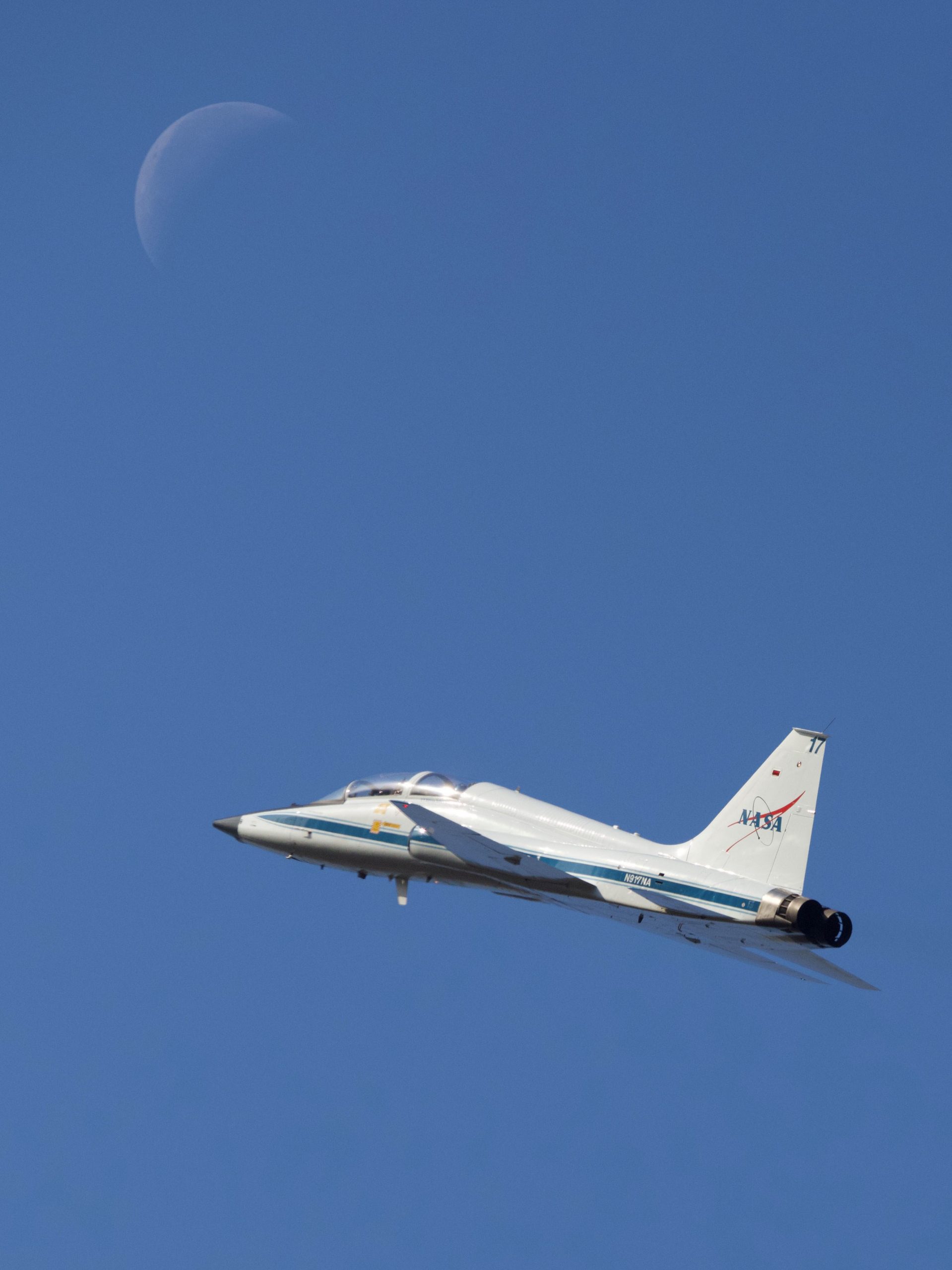 Artemis II Crew Trains on T-38 – NASA astronaut Christina Koch and Canadian Space Agency astronaut Jeremy Hansen take off on a T-38 training flight from Ellington Field on Feb. 11, 2026, as a waning crescent Moon hovers above.