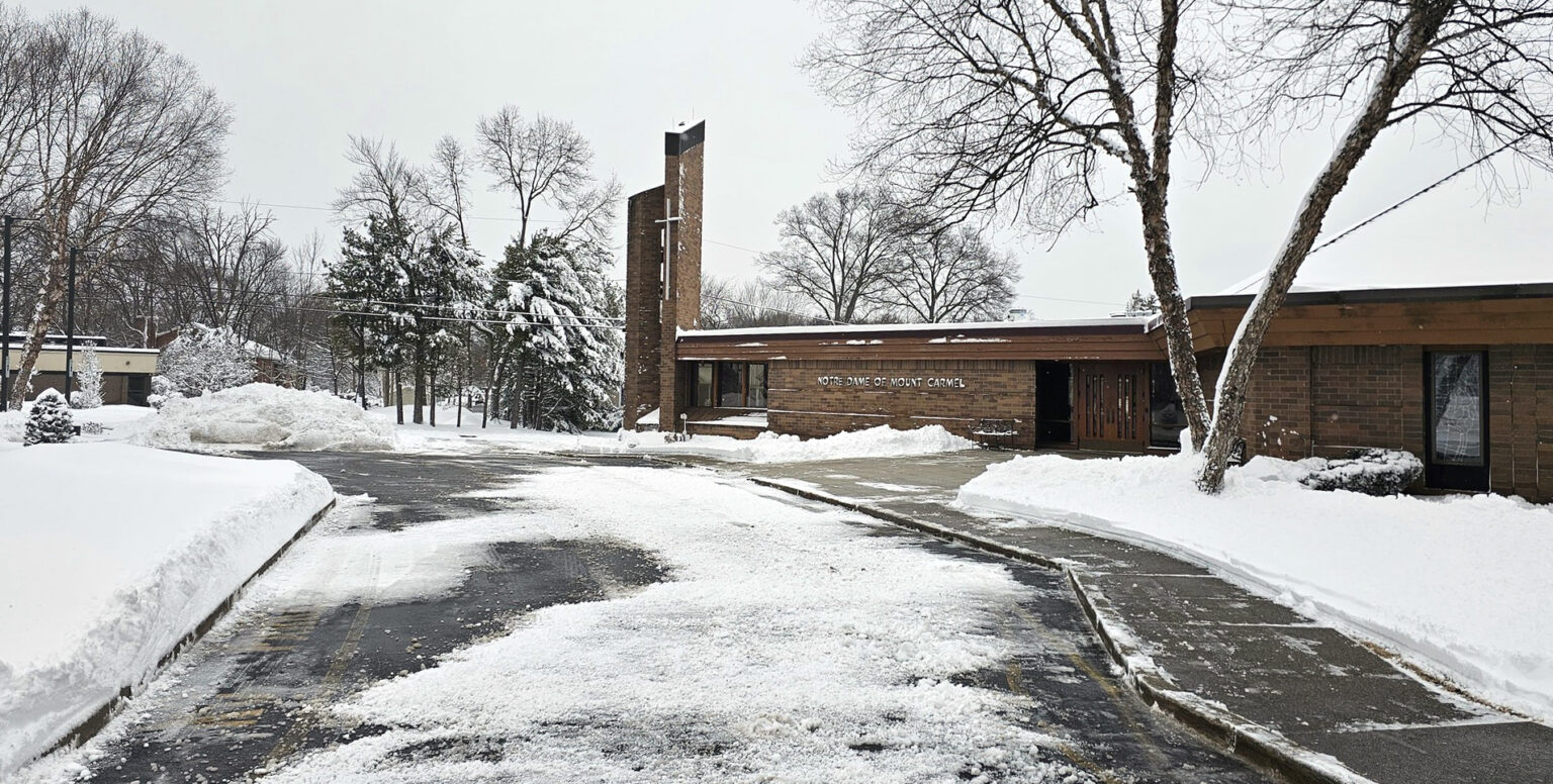 Diocese braces for more snow after blizzard socks State #Catholic – Parishes and schools in the Paterson Diocese in New Jersey are bracing for more snow on Wednesday and Friday after life started returning to normal in the aftermath of a powerful blizzard that dumped nearly 2 feet of snow on New Jersey between Sunday and Monday. The Bomb Cyclone Blizzard — the largest in the Garden State in 30 years — crippled the area, making travel impossible, disrupting diocesan activities, and forcing the closure of parishes and schools.
The storm caused the cancellation of the annual Rite of Election on Sunday afternoon, with Bishop Kevin J. Sweeney at the Cathedral of St. John the Baptist in Paterson, N.J. Many parishes also cancelled Masses; other activities, such as religious education, and opportunities for confession on Monday for the first night of Welcome Home to Healing, a diocesan Lenten initiative. St. Anthony Parish in Hawthorne, N.J., cancelled its Lenten mission on Monday because the speaker couldn’t secure a flight, but continued it on Tuesday.
Many schools in the diocese reopened on Tuesday, while others remained closed due to ongoing safety concerns or snow-removal efforts. During an already brutal winter, the Church of Paterson faces 1 to 3 inches of snow on Wednesday and again on Friday with a wintry mix and 4-8 inches through the morning, according to News 12.

Click here to subscribe to our weekly newsletter.

St. Gerard Parish in Paterson held regular Sunday Masses and a Monday Mass, which was livestreamed and attended by one churchgoer. Paterson received up to 14 inches of snow. The parish school was closed on Monday and Tuesday. Msgr. George Hundt, pastor of St. Gerard’s and
Our Lady of Pompei Parish, also in Paterson, moved his weekly livestreamed reflection from 7 p.m. to 4 p.m. on Sunday.
“We got dug out fine, but we are tired of the snow,” said Msgr. Hundt, echoing the sentiments of many in the diocese.
Erring on the side of caution, the diocese cancelled the Rite of Election. During the rite, the Catholic Church officially selects and enrolls unbaptized catechumens for the Sacraments of Initiation — Baptism, Confirmation, and Eucharist — at the Easter Vigil. The Rite of Election will not be rescheduled.
“Arrangements will be made for the signing of the Book of the Elect by Bishop Sweeney at a future date,” Father Jared J. Brogan, director of the diocesan Worship Office, wrote about the Rite of Election cancellation. “We continue to pray for all those preparing for initiation and for those who accompany them.”
On Sunday, St. Peter the Apostle Parish in Parsippany, N.J., conducted the Rite of Sending part of the Rite of Election for its four catechumens, omitting Bishop Sweeney’s part. Like in many parishes, Father David Pickens, St. Peter’s pastor, cancelled the Monday morning Masses — something he has never done — and closed the parish’s offices.
But unlike most parishes, St. Peter’s held a Mass at 7 p.m., followed by confession that night for the Welcome Home to Healing initiative. Each parish in the Church of Paterson opens its doors for confession every Monday of Lent at 7 p.m. to encourage people to receive God’s healing and return to church.
“We did well with the storm, but the snow is killing us,” said Father Pickens, expressing the concerns of parishes that are shouldering increased snow-removal costs because of a spike in snowfall this winter. Some parishes have asked their faithful to help cover the additional expense.
The northernmost parishes in the diocese, St. Thomas the Apostle in Sandyston, N.J., and St. James the Greater in Montague, N.J., reported that they weren’t hit with the “full amount of snow expected and were spared strong wind gusts.”
Parishes and schools used social media not only to announce storm-related information, but also to share updates and resources. Villa Walsh Academy in Morristown, N.J., stated, “Mother Nature clearly did not get the memo that we are ready for spring.” St. Paul Parish in Clifton, N.J., offered hope from Psalm 46:1: “God is our refuge and strength, our very soon help in tribulations.”
On Tuesday, the Academy of St. Elizabeth in the Convent Station neighborhood of Morris Township, N.J., implemented Virtual Learning Day. On that day, many schools, such as St. Patrick School in Chatham, N.J., had a delayed opening, following the direction of their local public school district.
“It’s wonderful to be back. There is nothing quite like the energy of the children returning to the building after a storm,” Dr. Christine Ross, St. Patrick’s principal, texted BeaconNJ.org on Tuesday. “Our facilities team did a fantastic job; our property was completely cleared and safe, as were the surrounding streets.”
Pictured is Notre Dame of Mount Carmel Parish in the Cedar Knolls neighborhood of Hanover Township, N.J., covered in snow after a powerful blizzard dumped nearly 2 feet of snow on New Jersey between Sunday and Monday.
