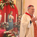 Faith and unity as Paterson parish honors martyred patroness #Catholic - St. Agnes Parish in Paterson, N.J., on Feb. 1 welcomed Bishop Kevin J. Sweeney, who celebrated a Spanish Mass for the parish’s patroness, St. Agnes, virgin and martyr, whose feast day is Jan. 21. She is the patron saint of girls, chastity, Girl Scouts, engaged couples, and virgins.
Bishop Sweeney celebrated the Mass with Father Milton Camargo, St. Agnes’ pastor, who was concelebrating. They wore red vestments to mark the patron saint’s death as a martyr. Deacon Ambioris Gomez and Deacon Gilberto Vazquez assisted with the liturgy. Bishop Sweeney censed a St. Agnes statue in the church.

Click here to subscribe to our weekly newsletter.

Legend has it that St. Agnes was a girl many young men wanted to marry. Among those she refused, one reported her to authorities for being a Christian. She was arrested, condemned, executed, and buried near Rome in a catacomb that eventually was named after her. The daughter of Constantine, the Roman emperor, built a basilica in her honor.
During the Mass, some pews at St. Agnes were reserved for children preparing for first Holy Communion and Confirmation.
“Their presence was intentional and pastoral. One essential part of preparing for the sacraments is active participation in the Eucharist. If children are prepared for the sacraments without learning to love and participate in the Mass, we often do not see them continue in the life of the Church afterward,” said Father Camargo, adding that, at the same time, the parents of these children are also receiving formation classes. “Our goal is to help them grow as the first catechists of their children. As we often say, ‘No one can give what they do not have,’ so the formation of parents is just as important as the formation of the children,” he said.
BEACON PHOTOS | JOE GIGLI
 [See image gallery at beaconnj.org] &nbsp;
