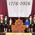 Hawthorne school marks nation’s birthday with Catholic Schools Week activities #Catholic - St. Anthony School in Hawthorne, N.J., kicked off Catholic Schools Week with a learning fair and open house honoring the nation’s 250th birthday. All students participated along with many parents, faculty and staff.
Students from pre-K to first grade depicted the life of a child in 1776 through hands-on activities such as completing chores, playing games, doing schoolwork, and participating in social dancing. Second grade brought the Founding Fathers to life through a living museum, while the third grade re-enacted the Boston Tea Party.
Fourth-grade students showcased their studies and utilized their STEM skills to design wigwams and longhouses while studying the Native Americans of the Northeast Region during the Revolutionary period.

Click here to subscribe to our weekly newsletter.

Sixth-grade students presented their research on a variety of colonial topics, including trade, occupations, roles of women, fashion, food, medicine, spies, the military, notable figures such as George Washington and Phillis Wheatley, and Native Americans. They also demonstrated how to make clay beads and marbles. Seventh grade students explored colonial engineering as millwrights, designing and building waterwheels used to power sawmills, flour mills, and textile mills. They calculated the work, power, and horsepower generated by their waterwheels.
The eighth grade capped off the day with reenactments of the signing of the Declaration of Independence and Washington Crossing the Delaware.
 [See image gallery at beaconnj.org]