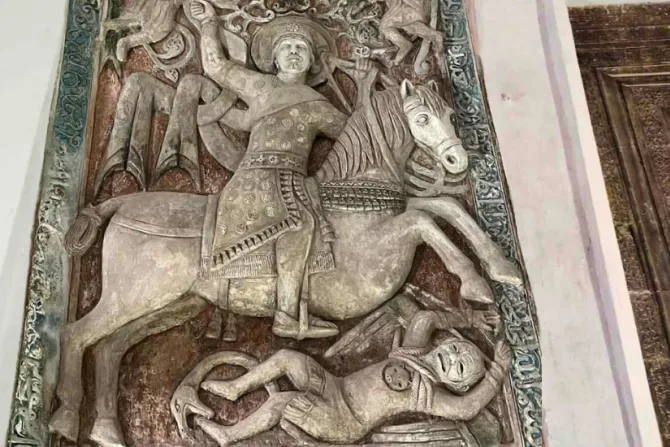 Historic murals in Iraq emerge from the ruins of ISIS destruction – #Catholic – Restoration work is progressing rapidly on two 13th-century historic mural reliefs at the ancient Mar Behnam and Sarah Monastery in Iraq. The effort is being led by the monastery’s administration in collaboration with the French organization Mesopotamia after the artworks suffered extensive destruction at the hands of ISIS.The monastery was featured in an EWTN News special on Iraq marking 10 years since the rise of ISIS and examining Christianity in Iraq a decade after the extremist group’s occupation. The report highlighted both the destruction inflicted on Christian heritage and the steady efforts toward restoration, with Mar Behnam Monastery standing as a visible sign of endurance and renewal.The murals, depicting the “Martyrdom of Mar Behnam” and “Saint Sarah,” face one another inside the monastery church and are considered unique in both scale and artistic detail. No other monastery today contains comparable works in terms of size, age, and creative intricacy. They have long been objects of popular devotion in addition to their historical value, as Chorbishop Mazen Mattoka, the monastery’s superior, explained to ACI MENA, the Arabic-language sister service of EWTN News.
Father Mazen Mattoka, superior of the ancient Mar Behnam and Sarah Monastery in Iraq. | Credit: Photo courtesy of Father Mazen Mattoka
ISIS militants devastated the two plaster murals in an attempt to erase Christian heritage and obliterate artworks that had withstood centuries of challenges. Despite the severity of the damage and the high cost of restoration, multiple coordinated efforts, which Mattoka describes as guided by divine providence, have worked to lift the dust and darkness of ISIS from the sacred images.Mattoka believes providence led French journalist Pascal Makosian to visit the monastery and recognize the profound pain caused by the vandalism. Through his organization, Mesopotamia, Makosian undertook the restoration project under the sponsorship of the Syriac Catholic Archdiocese of Mosul, in consultation with the Nineveh Antiquities Inspectorate and with the work of local artists.The murals are distinguished by rich symbolic colors: royal blue framing the inscriptions as a symbol of heaven; red signifying martyrdom; and green representing continuity and eternal life. Their uniqueness is further deepened by encoded theological meaning. At the center, Mar Behnam is depicted mounted on his horse; below him appears a scene symbolizing the defeat of evil; and above, two angels carry the martyred saint into the kingdom, representing resurrection.The mural of St. Sarah measures approximately 2 meters (6.6 feet) in height and nearly 1 meter (3.3 feet) in width, appearing modest beside the larger Mar Behnam mural, which extends nearly 4 meters (13.1 feet) in length and 2 meters (6.6 feet) in width. Both are framed by inscriptions in Arabic and Syriac, according to Mattoka.Extensive damageThe two plaster murals suffered destruction estimated at nearly 80%, according to sculptor Thabet Michael, head of the restoration team. He explained that ISIS left little more than the outer frame intact, from which the restoration process began.Michael had participated in the previous restoration of the murals in 2011, gaining experience that proved essential in confronting current challenges — particularly the complete disfigurement of sculptural features and the erasure of facial details.He praised the French team’s study of the murals and their history, as well as the preparation of a comprehensive photographic archive. By consulting the oldest available images — including photographs taken by foreign travelers in 1904, despite their lack of color and facial detail — restorers were able to approximate the original appearance as closely as possible.Approaching the originalThe restoration was carried out using the same original raw materials — gypsum mixed with lime — with additional elements to enhance cohesion and durability. The murals’ original colors, which had faded over centuries, were restored using comparable pigments. Surviving fragments of colored sections were analyzed to achieve shades closest to the original work, created by Syriac artists of Tikriti origin known for their mastery of sculpture, calligraphy, and ornamental design.Michael emphasized the necessity of returning to historical sources and studying them carefully in order to reach satisfactory results in restoring any historic artwork. He added that the completed work reflects the Atabeg artistic style prevalent at the time of the murals’ creation, blended with local Iraqi elements and inspired by Assyrian civilization.This story was first published by ACI MENA, the Arabic-language sister service of EWTN News. It has been translated and adapted by EWTN News. Historic murals in Iraq emerge from the ruins of ISIS destruction – #Catholic – Restoration work is progressing rapidly on two 13th-century historic mural reliefs at the ancient Mar Behnam and Sarah Monastery in Iraq. The effort is being led by the monastery’s administration in collaboration with the French organization Mesopotamia after the artworks suffered extensive destruction at the hands of ISIS.The monastery was featured in an EWTN News special on Iraq marking 10 years since the rise of ISIS and examining Christianity in Iraq a decade after the extremist group’s occupation. The report highlighted both the destruction inflicted on Christian heritage and the steady efforts toward restoration, with Mar Behnam Monastery standing as a visible sign of endurance and renewal.The murals, depicting the “Martyrdom of Mar Behnam” and “Saint Sarah,” face one another inside the monastery church and are considered unique in both scale and artistic detail. No other monastery today contains comparable works in terms of size, age, and creative intricacy. They have long been objects of popular devotion in addition to their historical value, as Chorbishop Mazen Mattoka, the monastery’s superior, explained to ACI MENA, the Arabic-language sister service of EWTN News.
Father Mazen Mattoka, superior of the ancient Mar Behnam and Sarah Monastery in Iraq. | Credit: Photo courtesy of Father Mazen Mattoka
ISIS militants devastated the two plaster murals in an attempt to erase Christian heritage and obliterate artworks that had withstood centuries of challenges. Despite the severity of the damage and the high cost of restoration, multiple coordinated efforts, which Mattoka describes as guided by divine providence, have worked to lift the dust and darkness of ISIS from the sacred images.Mattoka believes providence led French journalist Pascal Makosian to visit the monastery and recognize the profound pain caused by the vandalism. Through his organization, Mesopotamia, Makosian undertook the restoration project under the sponsorship of the Syriac Catholic Archdiocese of Mosul, in consultation with the Nineveh Antiquities Inspectorate and with the work of local artists.The murals are distinguished by rich symbolic colors: royal blue framing the inscriptions as a symbol of heaven; red signifying martyrdom; and green representing continuity and eternal life. Their uniqueness is further deepened by encoded theological meaning. At the center, Mar Behnam is depicted mounted on his horse; below him appears a scene symbolizing the defeat of evil; and above, two angels carry the martyred saint into the kingdom, representing resurrection.The mural of St. Sarah measures approximately 2 meters (6.6 feet) in height and nearly 1 meter (3.3 feet) in width, appearing modest beside the larger Mar Behnam mural, which extends nearly 4 meters (13.1 feet) in length and 2 meters (6.6 feet) in width. Both are framed by inscriptions in Arabic and Syriac, according to Mattoka.Extensive damageThe two plaster murals suffered destruction estimated at nearly 80%, according to sculptor Thabet Michael, head of the restoration team. He explained that ISIS left little more than the outer frame intact, from which the restoration process began.Michael had participated in the previous restoration of the murals in 2011, gaining experience that proved essential in confronting current challenges — particularly the complete disfigurement of sculptural features and the erasure of facial details.He praised the French team’s study of the murals and their history, as well as the preparation of a comprehensive photographic archive. By consulting the oldest available images — including photographs taken by foreign travelers in 1904, despite their lack of color and facial detail — restorers were able to approximate the original appearance as closely as possible.Approaching the originalThe restoration was carried out using the same original raw materials — gypsum mixed with lime — with additional elements to enhance cohesion and durability. The murals’ original colors, which had faded over centuries, were restored using comparable pigments. Surviving fragments of colored sections were analyzed to achieve shades closest to the original work, created by Syriac artists of Tikriti origin known for their mastery of sculpture, calligraphy, and ornamental design.Michael emphasized the necessity of returning to historical sources and studying them carefully in order to reach satisfactory results in restoring any historic artwork. He added that the completed work reflects the Atabeg artistic style prevalent at the time of the murals’ creation, blended with local Iraqi elements and inspired by Assyrian civilization.This story was first published by ACI MENA, the Arabic-language sister service of EWTN News. It has been translated and adapted by EWTN News.