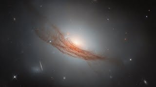 Hubble Spots Lens-Shaped Galaxy – This NASA/ESA Hubble Space Telescope image of NGC 7722, a lenticular galaxy located about 187 million light-years away, features concentric rings of dust and gas that appear to swirl around its bright nucleus.