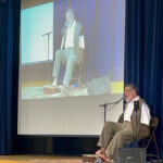 Tony Meléndez inspires students at St. Vincent Martyr School during Catholic Schools Week #Catholic – Students at St. Vincent Martyr School welcomed internationally known musician and speaker Tony Meléndez during a special assembly held Jan. 27 as part of Catholic Schools Week.
The assembly brought together students across grade levels, with younger students seated alongside their older-grade buddies. Meléndez performed several songs, playing the guitar with his feet. Born without arms, he is an accomplished guitarist, singer, and composer whose music and message focus on perseverance, faith, and believing in one’s God-given abilities.

Click here to subscribe to our weekly newsletter.

Meléndez and his brother, José, also spoke about the unkindness Tony faced as a child and how both brothers learned to overcome adversity through resilience, faith, and love. José shared a childhood story in which he once wished for a brother who could play Frisbee with him. Their mother’s response — “Love him the way he is” — became a turning point.
Not long after, Tony invited his brother to play Frisbee. José threw the Frisbee, and Tony caught it under his chin, flipped it to his foot, and sent it back into the air. The brothers later re-created that moment during the assembly, drawing applause from students and staff.
Meléndez also shared a video clip of himself performing for St. Pope John Paul II, who was so moved by the performance that he descended from his viewing box to greet and bless him.
The assembly concluded with students offering prayer intentions for family members, friends, and those in need, reinforcing the message of compassion and community central to Catholic Schools Week.
 Click here for more information about St. Vincent Martyr School.