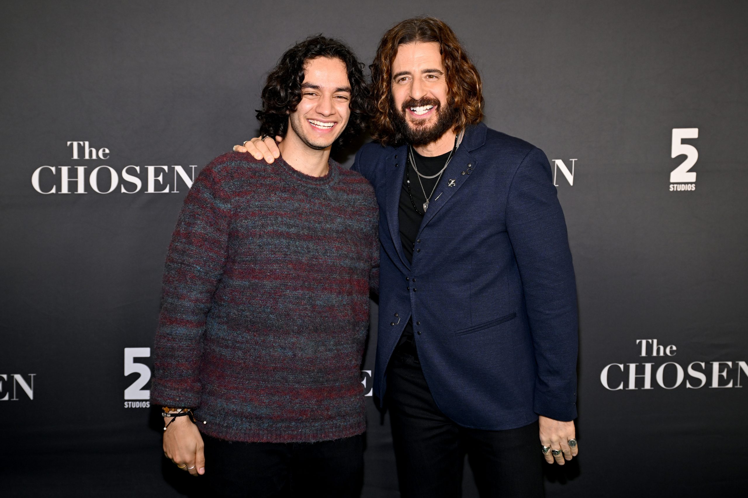 ChosenCon 2026: ‘This is the Comic-Con of the Bible’ #Catholic Thousands of fans of the hit series “The Chosen” gathered at the Charlotte Convention Center in Charlotte, North Carolina, Feb. 19–21 for ChosenCon — a fan convention for the show.This year’s gathering also featured cast members from other shows from “The Chosen” universe including “The Chosen Adventures” and 5&2 Studios’ next series, “Joseph of Egypt,” as well as Amazon MGM Studios and the Wonder Project’s “House of David.”“This is huge. This is the Comic-Con of the Bible,” Michael Iskander, the actor who portrays King David in “House of David,” told EWTN News on the teal carpet.This was the young actor’s first time attending ChosenCon. He participated in a panel discussion alongside star of “The Chosen” Jonathan Roumie and Adam Hashmi, the actor who will portray Joseph in “Joseph of Egypt.”“I’ve wanted to come to ChosenCon for such a long time as a fan but I’m here as a guest. So this is really, really special,” he said.Speaking about his panel, Iskander said: “Everybody has been so warm. It was Jonathan and Adam and I and we had a really, really amazing conversation about what it means to play these biblical characters, how it affects us, how it’s changed us and what these biblical characters mean to everyone who is watching.”
 
 Michael Iskander and Jonathan Roumie at ChosenCon in Charlotte, North Carolina, on Feb. 20, 2026. | Credit: Photo courtesy of 5&2 Studios
 
 Many of the actors in attendance highlighted the importance the fans have played in the success of “The Chosen” and shared their feelings on the fact that they only have one season left to film.“I remember in Season 1 we had like five superfans that would follow us around — by the way those five same fans we can see around here on occasion. So if we do see them we’re just like ‘Oh my goodness — here since the beginning,’” said George Xanthis, the actor who portrays the apostle John in “The Chosen.” “But they’re just as important as the fans that have been here for two years or one year or six years or whatever it is but remembering back to that time, we were so grateful that we even had five fans.”He added: “So I take that feeling into things like today and it’s not lost on me how lucky I am, and how lucky we all are as a series and as a cast and as a production. So when days like this come about I just try to give my all. I want to say ‘Hi’ to as many people as possible.”
 
 Actor George Xanthis takes pictures with fans at ChosenCon in Charlotte, North Carolina. | Credit: Courtesy of 5&2 Studios
 
 Paras Patel, who plays Matthew, called his time on the show “a gift and a blessing.”“In many ways I have learned so much about myself being on the show and strengthened myself through it that I’m excited to see what will happen after,” he shared. “I kind of don’t want it to end because I just love these guys and I love our crew, but, as they say, all good things must come to an end.”An actor who has been deeply impacted by his time portraying his character is Giavani Cairo, the actor who plays Thaddeus. The actor has spoken openly about growing up without his biological father and during a panel discussion at ChosenCon discussed a moment of healing he received while filming.“He’s [Thaddeus] impacted me in ways that I could not have even imagined,” he told EWTN News.He shared that a few months before booking the role on “The Chosen,” he decided to “renew” his faith.“I started reading the Bible every day, talking to God like he was a friend, and that’s when the audition for ‘The Chosen’ came — at the right moment, right time,” he said. “And they always say God finds you in those moments.”He added: “So for me it started a healing process. I always had a chip on my shoulder wanting to prove that I was worthy. And he’s made me reflective that I am worthy of his love, and I’m worthy of other people’s love as well. So I just wanted to make people feel seen through Thaddeus that we all do matter.”
 
 Nearly 5,000 fans attended the third ChosenCon, which was held in Charlotte, North Carolina, Feb. 19–21, 2026. | Credit: Courtesy of 5&2 Studios
 
 While details of Season 6 of “The Chosen” are still largely under wraps, Roumie briefly discussed his experience portraying the Lord’s passion and crucifixion.“For the first few months afterwards going to Mass — and even thinking about it now — I just get weepy. I get emotional. It’s hard. It’s left an indelible impression on me — mentally and emotionally sharing even just a percentage, a micron of a percentage of the Lord’s passion playing it and reenacting it has left me absolutely humbled and moved,” he told EWTN News.Monsignor Patrick J. Winslow, vicar general and chancellor of the Diocese of Charlotte, was grateful that his city was hosting the conference and called the event “inspiring to the faithful.”“I think it’s such a beautiful new art form — a series — and to take the Gospel story in elevated form of that art form and present it for the world in a way that so many people can view and resonate with is just an extraordinary feat,” he said.Winslow added: “When you present a faithful rendition of Our Lord, or a faithful rendition of the Gospel, or David, or for that matter any story of faith, but you do it in a way that’s very well done, very well produced, it’s striking chords that very few people have access to. They’re deep within. And when you strike those chords with people, it inspires.”