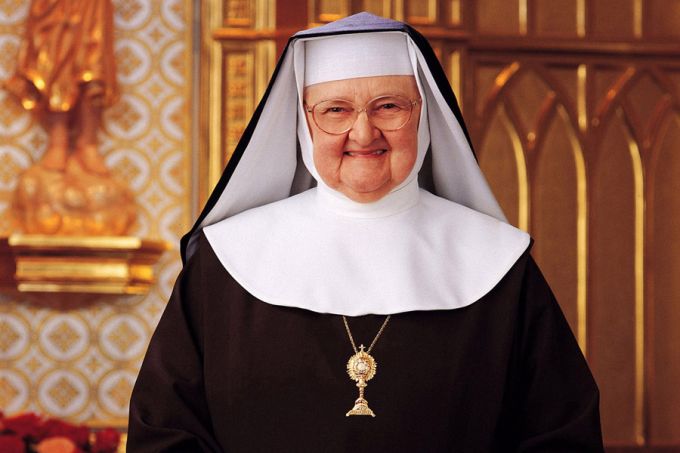 10 powerful quotes from Mother Angelica about faith and the love of Jesus #Catholic Mother Angelica was a Poor Clare nun and the dynamic foundress of EWTN, whose bold faith and candid teaching style brought millions closer to Christ through her television ministry. Born on April 20, 1923, she would have turned 103 years old this year.In honor of her birthday, here are 10 quotes from Mother Angelica about the love of Jesus and the beauty and challenge of living a life of faith:“Faith is often most alive when everything feels dark. That is when you choose to believe that God is there, even when you cannot see him or feel him. That kind of faith pleases God the most — because it is pure trust.”“Holiness is not for wimps and the cross is not negotiable, sweetheart — it’s a requirement.”“Jesus asks me to go to him when I am overburdened. He did not promise to take away those burdens, for I must carry mine as he carried his.”“Every Christian who strives for holiness of life experiences dryness of soul. It is to most people a heartrending experience. It is a paradox, for the soul becomes confused when it realizes the harder it strives the further away Jesus seems to be.”“The heart of Jesus is compassionate and understanding. It has felt the sting of ingratitude, and when my heart suffers from that same offense, I can turn to him, and he understands my feelings.”“Jesus feels my sorrow greater than I, for his love is infinite, and he suffers in an infinite way.”“Sometimes my worst day — one filled with pain and suffering — in the eyes of God, is my best day if Iʼve born it cheerfully and Iʼve born it with love.”“Faith is what gets you started. Hope is what keeps you going. Love is what brings you to the end.”“Faith is one foot on the ground, one foot in the air, and a queasy feeling in the stomach.”“You see, God expects his people to do the ridiculous so he can do the miraculous.”