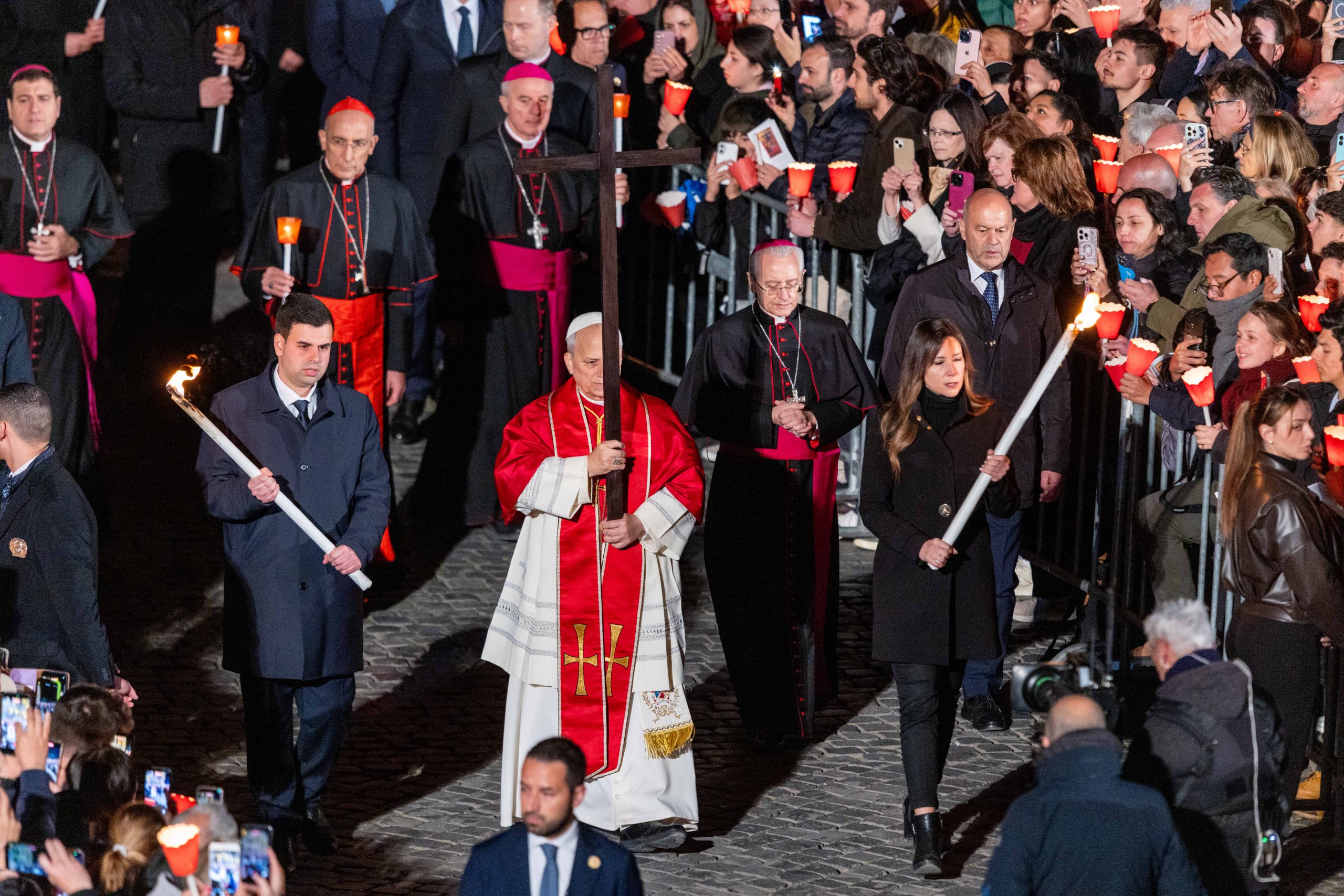 At the Colosseum, Pope Leo XIV urges the faithful to ‘live our lives as a journey’ in Christ’s love – #Catholic – Pope Leo XIV urged the faithful to “live our lives as a journey” and prayed for the Church to “follow in the footprints” of Christ as he walked the Via Crucis on April 3.The pope personally carried the cross through every station of the Good Friday Way of the Cross at the Colosseum, the first time in four years the figure of the Supreme Pontiff has been present at the amphitheater. Due to health concerns, Pope Francis last participated in person at the Colosseum in 2022, appearing via video after that. Leo told media earlier in the week that the event “will be an important sign, given what the pope represents: a spiritual leader in today’s world — a voice to proclaim that Christ still suffers.” "And I, too, carry all of this suffering in my prayers,” the pope said. The Via Crucis meditations for 2026 were written by Father Francesco Patton, the former Custos of the Holy Land. The reflections noted that “every authority must answer before God for the manner in which it exercises the power it has received,” including “the power to initiate a war or to end it” and “the power to trample upon human dignity or to safeguard it.” “Each one of us, too, is called to answer for the power we exercise in our daily lives,” the meditations said. At the conclusion of the Way of the Cross, the pope quoted Saint Francis of Assisi in praying that God would “give us miserable ones the grace to do for you alone what we know you want us to do and always to desire what pleases you.”“Inwardly cleansed, interiorly enlightened and inflamed by the fire of the Holy Spirit, may we be able to follow in the footprints of your beloved Son, our Lord Jesus Christ,” the pope prayed. This story was originally published by ACI Stampa, EWTN News' Italian-language partner agency. It has been translated and adapted by EWTN News English. At the Colosseum, Pope Leo XIV urges the faithful to ‘live our lives as a journey’ in Christ’s love – #Catholic – Pope Leo XIV urged the faithful to “live our lives as a journey” and prayed for the Church to “follow in the footprints” of Christ as he walked the Via Crucis on April 3.The pope personally carried the cross through every station of the Good Friday Way of the Cross at the Colosseum, the first time in four years the figure of the Supreme Pontiff has been present at the amphitheater. Due to health concerns, Pope Francis last participated in person at the Colosseum in 2022, appearing via video after that. Leo told media earlier in the week that the event “will be an important sign, given what the pope represents: a spiritual leader in today’s world — a voice to proclaim that Christ still suffers.” "And I, too, carry all of this suffering in my prayers,” the pope said. The Via Crucis meditations for 2026 were written by Father Francesco Patton, the former Custos of the Holy Land. The reflections noted that “every authority must answer before God for the manner in which it exercises the power it has received,” including “the power to initiate a war or to end it” and “the power to trample upon human dignity or to safeguard it.” “Each one of us, too, is called to answer for the power we exercise in our daily lives,” the meditations said. At the conclusion of the Way of the Cross, the pope quoted Saint Francis of Assisi in praying that God would “give us miserable ones the grace to do for you alone what we know you want us to do and always to desire what pleases you.”“Inwardly cleansed, interiorly enlightened and inflamed by the fire of the Holy Spirit, may we be able to follow in the footprints of your beloved Son, our Lord Jesus Christ,” the pope prayed. This story was originally published by ACI Stampa, EWTN News' Italian-language partner agency. It has been translated and adapted by EWTN News English.