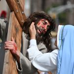Gripping Paterson Passion Play brings Christ’s sacrifice to life #Catholic - The annual reenactment of Jesus’ agonizing journey to his crucifixion on Mount Calvary was presented by the Cathedral of St. John the Baptist in Paterson, N.J., on Good Friday, April 3. Beginning outside the cathedral, the event moved through city streets before concluding inside, with thousands of captivated onlookers following the procession.





The Passion Play, called Via Crucis or the Way of the Cross, was performed in English and Spanish by over 100 actors from the cathedral on Good Friday. Parishioners assisted with the production. As the procession advanced along the mile-long route under sunny skies, prayers and reflections were offered at designated stops. The reenactment ended with Jesus’ crucifixion at the altar inside the cathedral.

Click here to subscribe to our weekly newsletter.

Following the reenactment, Bishop Sweeney led a Good Friday service, including veneration of the cross and the celebration of Holy Communion for the faithful, inside St. John’s.
BEACON PHOTOS | JOE GIGLI
 [See image gallery at beaconnj.org] &nbsp;