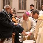 Holy Thursday in Paterson: Bishop embodies Christ’s servant love #Catholic - On behalf of the Paterson Diocese in New Jersey, Bishop Kevin J. Sweeney prayerfully asked Jesus, “Help us to know you, in your body, blood, soul, and divinity, in the Eucharist” while presiding over a bilingual Mass of the Lord’s Supper on April 2, Holy Thursday evening, at the Cathedral of St. John the Baptist in Paterson, N.J.
The Mass commemorates the institution of the sacraments of the Eucharist and Holy Orders by Jesus Christ. Just as Jesus washed the feet of his disciples at the Last Supper, Bishop Sweeney washed the feet of select faithful to symbolize the service and charity of Christ, who came “not to be served, but to serve.” By example of washing his disciples’ feet, Jesus demonstrated how Christians are to love one another through humble service.

Click here to subscribe to our weekly newsletter.

During his homily in English and Spanish, Bishop Sweeney asked Christ, “Help us to love as you love, help us to watch one another’s feet. Help us to be with Mary when we share in the mystery of the cross and to know that you have conquered sin and death.” He then added, “How happy and blessed are we to be called, to be here at the supper of the Lamb.”
Msgr. Geno Sylva, the cathedral’s rector and diocesan vicar for special projects, concelebrated the Mass with Bishop Sweeney. Father Jared Brogan, director of the diocesan Worship Office, was the master of ceremonies.
The Mass was followed by an outdoor procession with the Blessed Sacrament to the gym, where adoration was held until midnight.
BEACON PHOTOS | JOE GIGLI
 [See image gallery at beaconnj.org] &nbsp;