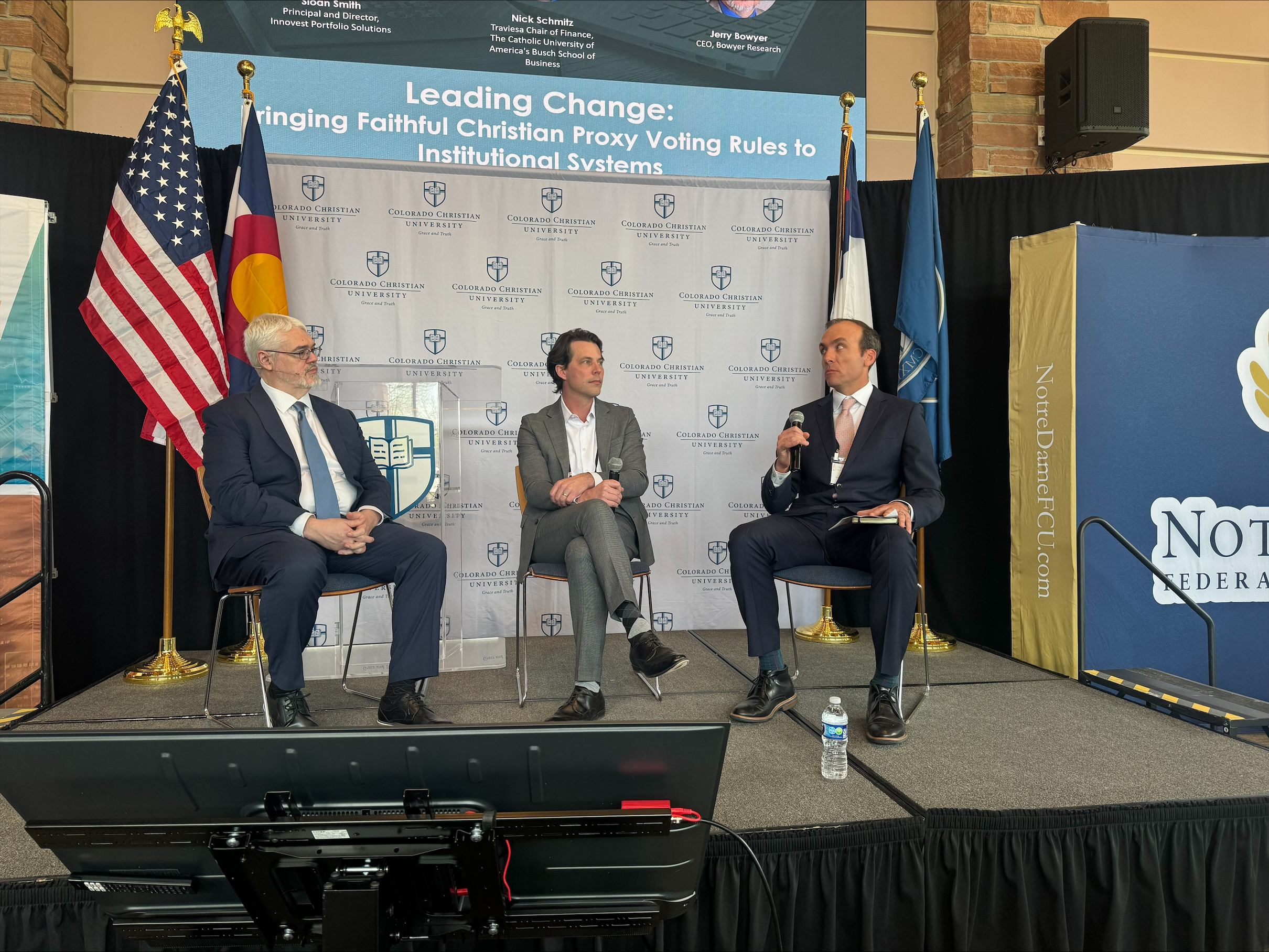 Investing with ‘the lordship of Christ’ in mind: Ecumenical business conference convenes in Denver – #Catholic – Remembering "the lordship of Christ is over everything,” Catholic and Protestant leaders are prioritizing ethical investing by making their voices heard as shareholders. At the 2026 Christian Institutional Investors conference in Lakewood, Colorado, on April 8, speakers urged Christian businesses, schools, and apostolates to stand up for their beliefs as investors. More than 150 attendees from across the country attended the conference, which was hosted by the faith-based investment consulting company Innovest Portfolio Solutions along with the Archdiocese of Denver, Catholic Benefits Association, The Catholic Foundation of Northern Colorado, AmPhil, Alliance Defending Freedom, and Colorado Christian University, where the event took place.“This ecumenical gathering brings together Catholic and Protestant leaders to explore portfolio screening, values alignment with asset managers, and the importance of proxy voting and corporate engagement,” Innovest principal Sarah Newman said.“Our goal is for attendees to leave informed, inspired, and equipped to better understand how their portfolios are built and why the partners they choose truly matter to create returns they need for their Christian mission,” Newman told EWTN News.Fighting for Christian values through proxy votingIn the fight to bring Christian values into investing, speakers emphasized the importance of proxy voting — a process where shareholders authorize someone else to vote on their behalf in shareholder meetings.“As a shareholder, youʼre sort of a citizen of a company and are entitled to vote on these matters — but most people donʼt realize that their proxies are being delegated to an adviser and unintentionally support things that are opposed to their own values,” speaker Dustin DeVito said.DeVito is a research director at the 1792 Exchange, a company working to bring “ideological balance back to public corporations.”Nicholas Schmitz, the Traviesa chair of finance at The Catholic University of America’s Busch School of Business, noted that Christian investors “need a custom proxy option that actually represents Christian viewpoints” to have a cumulative, widespread impact across corporate America.Custom proxy options enable institutions to vote according to their own guidelines rather than the default options.“That would be a huge, huge uptake that would get long-term cultural change,” Schmitz said in a panel titled “Leading Change: Bringing Faithful Christian Proxy Voting Rules to Institutional Systems.”In November, The Catholic University of America developed new proxy guidelines that leading companies representing shareholders accepted — giving a faith-based option in line with the Catholic Churchʼs teachings.“Catholicism … I joke, weʼre the most organized religion in America, but the least organized in capital markets. We donʼt really have an excuse for not getting this right,” Schmitz said.In his talk, “The Post-ESG Landscape: Where Corporate America Is Headed and How Faith-Aligned Capital Can Lead,” DeVito also encouraged Christian investors to stand up for their faith.
A panel discusses the Christian Investing Movement on April 8, 2026. Left to right: Jeremy Beer of AmPhil, Richard Todd of Innovest, Derek Kreifels of Prospr Aligned, and Bridgett Wagner of The Heritage Foundation. | Credit: Photo courtesy of Innovest
“As Christians, we want to be the ones boldly leading because the lordship of Christ is over everything,” DeVito said. “So if thereʼs any issue in which companies are engaging in something thatʼs biased and thatʼs harming Christians, we need to be willing to have the courage and put ourselves out there and engage on the issue.”As an example, DeVito cited the debanking of Christians and conservatives. In 2025, President Donald Trump signed an executive order prohibiting banks and financial institutions from debanking clients based on their political or religious views after Christians and conservatives expressed concern about the controversial practice.“Even just with a small amount of shares and the willingness to engage these companies and to talk through the research, we end up seeing incredible wins,” DeVito continued. “All it takes is just some people willing to fight.”In his research at 1792, DeVito said he has seen a trend away from DEI (diversity, equity, and inclusion) initiatives and “ESG” (environmental, social, and governance) — politically-motivated standards that large companies subscribed to but that recently fell out of favor after criticism from conservatives.DeVito pointed to the work of Robby Starbuck, an influencer known for raising awareness of DEI policies at companies like Tractor Supply, as well as the Trump administration as defining moments in the decline of DEI and ESG.“For the first time in over 20 years, corporate America is headed back in the direction of depoliticizing and focusing on business,” DeVito said. “And this is good because the companies are supported for the value they bring in, the goods and services they provide, not for identifying and solving all the worldʼs problems.” Investing with ‘the lordship of Christ’ in mind: Ecumenical business conference convenes in Denver – #Catholic – Remembering "the lordship of Christ is over everything,” Catholic and Protestant leaders are prioritizing ethical investing by making their voices heard as shareholders. At the 2026 Christian Institutional Investors conference in Lakewood, Colorado, on April 8, speakers urged Christian businesses, schools, and apostolates to stand up for their beliefs as investors. More than 150 attendees from across the country attended the conference, which was hosted by the faith-based investment consulting company Innovest Portfolio Solutions along with the Archdiocese of Denver, Catholic Benefits Association, The Catholic Foundation of Northern Colorado, AmPhil, Alliance Defending Freedom, and Colorado Christian University, where the event took place.“This ecumenical gathering brings together Catholic and Protestant leaders to explore portfolio screening, values alignment with asset managers, and the importance of proxy voting and corporate engagement,” Innovest principal Sarah Newman said.“Our goal is for attendees to leave informed, inspired, and equipped to better understand how their portfolios are built and why the partners they choose truly matter to create returns they need for their Christian mission,” Newman told EWTN News.Fighting for Christian values through proxy votingIn the fight to bring Christian values into investing, speakers emphasized the importance of proxy voting — a process where shareholders authorize someone else to vote on their behalf in shareholder meetings.“As a shareholder, youʼre sort of a citizen of a company and are entitled to vote on these matters — but most people donʼt realize that their proxies are being delegated to an adviser and unintentionally support things that are opposed to their own values,” speaker Dustin DeVito said.DeVito is a research director at the 1792 Exchange, a company working to bring “ideological balance back to public corporations.”Nicholas Schmitz, the Traviesa chair of finance at The Catholic University of America’s Busch School of Business, noted that Christian investors “need a custom proxy option that actually represents Christian viewpoints” to have a cumulative, widespread impact across corporate America.Custom proxy options enable institutions to vote according to their own guidelines rather than the default options.“That would be a huge, huge uptake that would get long-term cultural change,” Schmitz said in a panel titled “Leading Change: Bringing Faithful Christian Proxy Voting Rules to Institutional Systems.”In November, The Catholic University of America developed new proxy guidelines that leading companies representing shareholders accepted — giving a faith-based option in line with the Catholic Churchʼs teachings.“Catholicism … I joke, weʼre the most organized religion in America, but the least organized in capital markets. We donʼt really have an excuse for not getting this right,” Schmitz said.In his talk, “The Post-ESG Landscape: Where Corporate America Is Headed and How Faith-Aligned Capital Can Lead,” DeVito also encouraged Christian investors to stand up for their faith.
A panel discusses the Christian Investing Movement on April 8, 2026. Left to right: Jeremy Beer of AmPhil, Richard Todd of Innovest, Derek Kreifels of Prospr Aligned, and Bridgett Wagner of The Heritage Foundation. | Credit: Photo courtesy of Innovest
“As Christians, we want to be the ones boldly leading because the lordship of Christ is over everything,” DeVito said. “So if thereʼs any issue in which companies are engaging in something thatʼs biased and thatʼs harming Christians, we need to be willing to have the courage and put ourselves out there and engage on the issue.”As an example, DeVito cited the debanking of Christians and conservatives. In 2025, President Donald Trump signed an executive order prohibiting banks and financial institutions from debanking clients based on their political or religious views after Christians and conservatives expressed concern about the controversial practice.“Even just with a small amount of shares and the willingness to engage these companies and to talk through the research, we end up seeing incredible wins,” DeVito continued. “All it takes is just some people willing to fight.”In his research at 1792, DeVito said he has seen a trend away from DEI (diversity, equity, and inclusion) initiatives and “ESG” (environmental, social, and governance) — politically-motivated standards that large companies subscribed to but that recently fell out of favor after criticism from conservatives.DeVito pointed to the work of Robby Starbuck, an influencer known for raising awareness of DEI policies at companies like Tractor Supply, as well as the Trump administration as defining moments in the decline of DEI and ESG.“For the first time in over 20 years, corporate America is headed back in the direction of depoliticizing and focusing on business,” DeVito said. “And this is good because the companies are supported for the value they bring in, the goods and services they provide, not for identifying and solving all the worldʼs problems.”